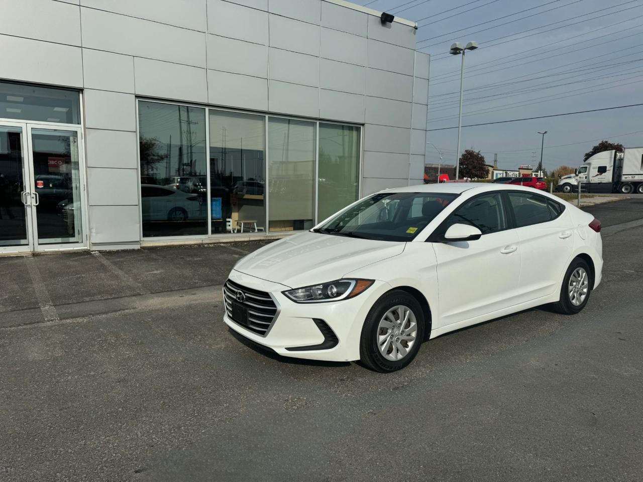 <p>Looking for a reliable and affordable sedan? Look no further than this 2017 Hyundai Elantra at Stephen Fitzgerald Motors. This white 4-door sedan comes with an automatic transmission, 4-cylinder engine, and front-wheel drive. With just 119,271 kilometers on the odometer, this Elantra is ready to take you wherever you need to go.</p><p>Enjoy a comfortable ride with heated front seats, heated mirrors, and power-adjustable seats. Stay connected with the AM/FM radio, auxiliary audio input, and steering wheel audio controls. And dont worry about winter weather with the rear window defroster and variable speed intermittent wipers.</p><p>This Elantra is loaded with safety features, including anti-lock brakes, brake assist, traction control, stability control, and multiple airbags. It also comes with keyless entry, power locks, power windows, and power mirrors for added convenience.</p><p>Here are five of the most exciting features this Hyundai Elantra has to offer:</p><ul><li><strong>Heated front seats:</strong> Stay warm and comfortable even on the coldest days.</li><li><strong>Heated mirrors:</strong> Clear vision in any weather.</li><li><strong>Power windows:</strong> Convenient one-touch operation for all windows.</li><li><strong>Keyless entry:</strong> Unlock your car without ever having to fumble with your keys.</li><li><strong>Steering wheel audio controls:</strong> Keep your hands on the wheel while controlling your music.</li></ul><p> </p>