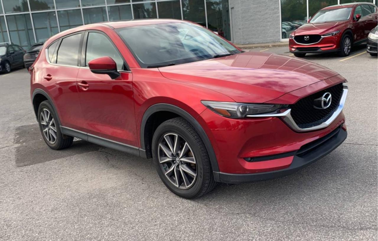 <div><strong>For Sale: 2018 Mazda CX-5 Grand Touring AWD  Sold with Safety Certification</strong></div><br /><div><strong>Price:</strong> $18,975 + tax & licensing<br><strong>Mileage:</strong> 147,800 kilometers</div><br /><div><strong>Purchase Options:</strong></div><ul><li><p><strong>Financing Available for Everyone:</strong> At Garage Plus Auto, we offer flexible financing options for all credit situations. Whether you have good credit, bad credit, or no credit, we can help you secure the best possible financing to fit your budget. We work with multiple lenders to ensure competitive rates and terms.</p></li><li><p><strong>Buy with Confidence:</strong> We sell vehicles via phone call for your convenience.</p></li><li><p><strong>Virtual Showings:</strong> We can show you the car via video call, allowing you to see every detail from anywhere.</p></li><li><p><strong>Nationwide Delivery:</strong> We offer delivery anywhere in Canada, right to your door.</p></li></ul><hr /><br /><div><strong>Features:</strong></div><ul><li><strong>Make:</strong> Mazda</li><li><strong>Model:</strong> CX-5 Grand Touring AWD</li><li><strong>Year:</strong> 2018</li><li><strong>Mileage:</strong> 147,800 kilometers</li><li><strong>Price:</strong> $18,975 + tax & licensing</li><li><strong>Safety Certification:</strong> Included</li><li><strong>Drivetrain:</strong> All-Wheel Drive (AWD)</li><li><strong>Blind Spot Monitor System:</strong> For enhanced safety</li><li><strong>Back-Up Camera:</strong> For easy parking and safety</li><li><strong>Fully Loaded:</strong> Comes with all premium features</li><li><strong>Heated Seats:</strong> For comfort in colder weather</li><li><strong>Sunroof:</strong> Adds a spacious feel and natural light</li><li><strong>Leather Upholstery:</strong> Premium interior materials</li></ul><hr /><br /><div><strong>Description:</strong><br>For sale is a well-appointed <strong>2018 Mazda CX-5 Grand Touring AWD</strong> with <strong>147,800 kilometers</strong>, available at a dealer price of <strong>$18,975</strong> plus tax and licensing. This stylish and versatile SUV is perfect for those seeking a comfortable ride without compromising on performance or features.</div><br /><div>Equipped with a <strong>blind spot monitor system</strong> for added safety, a <strong>back-up camera</strong> for easy maneuvering, and <strong>heated seats</strong> for comfort, this CX-5 is designed for both driver enjoyment and passenger comfort. The <strong>sunroof</strong> adds an extra touch of luxury, while the <strong>fully loaded</strong> interior ensures a premium experience on every journey.</div><hr /><br /><div>For more information or to schedule a test drive, please contact us:</div><br /><div><strong>Location:</strong><br>Garage Plus Auto<br>1201 Bank Street<br>Ottawa, ON K1S 3X7<br>Canada</div><br /><div><strong>Website:</strong> garageplusautocentre.com</div>