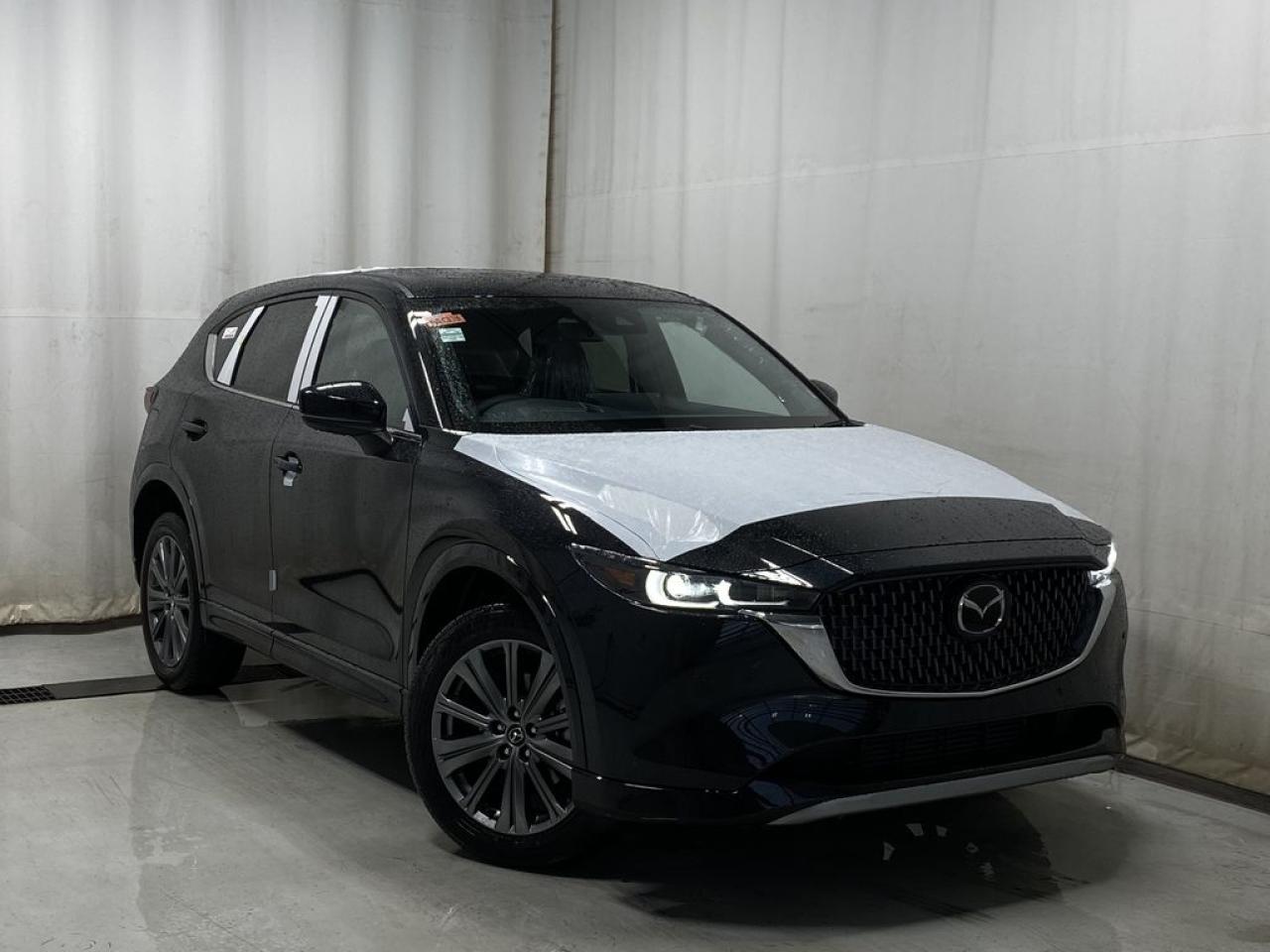 <p>NEW 2024 CX-5 Signature AWD. Bluetooth, Skyactiv-G 2.5 L (Inline-4) Dynamic Pressure Turbo. Backup Cam, 360° View Monitor, NAV, Interior Abachi Wood Trim, Nappa Leather Heated/Ventilated Seats, Power Front Seats, Memory Driver Seat, Rear Heated Seats, Wireless Apple CarPlay/Android Auto, Wireless Phone Charger, Bose Premium Sound System, Advanced Keyless Remote Entry, Tilt/Sliding Moonroof, Power Trunk, Adaptive Cruise Control, Heated Steering Wheel, Wiper Blade De-Icer, Auto Dual-Zone Climate Control, Rear Air Vents, Auto Rain-Sensing Wipers, F/R Parking Sensors, Electronic Parking Brake, Heated Mirrors, 19 Gunmetal Alloy Wheels</p>  <p>Includes:</p> <p>i-ACTIVSENSE + Safety Features (Smart City Brake Support-Front, Rear Cross Traffic Alert, Mazda Radar Cruise Control With Stop & Go, Distance Recognition Support System, Lane-Keep Assist System, Lane Departure Warning System, Advanced Blind Spot Monitoring)</p>  <p>A joy to drive, our 2024 Mazda CX-5 Signature AWD radiates refined style in Jet Black Mica! Motivated by a 2.5 Liter 4 Cylinder that delivers 256hp tethered to a paddle-shifted 6 Speed Automatic transmission. You can put that strength to good use with the added traction of torque vectoring, and this All Wheel Drive SUV returns nearly approximately 7.8L/100km on the highway. Our CX-5 also has an expressive design with bold details like 19-inch alloy wheels, a rear roof spoiler, and bright-tipped dual exhaust outlets.</p>  <p>Our Signature cabin is no ordinary interior. Its tailor-made for better travel with heated nappa leather power front seats, a leather-wrapped steering wheel, automatic climate control, pushbutton ignition, and keyless access. Mazda makes connecting easy by providing a 10.25-inch central display, a multifunction Commander controller, Apple CarPlay/Android Auto, Bluetooth, voice control, and six-speaker audio. The versatile rear cargo space adds adventure-friendly functionality.</p>  <p>Safety is a high priority for Mazda, which helps protect you and your loved ones with automatic emergency braking, adaptive cruise control, a rearview camera, lane-keeping assistance, blind-spot monitoring, and other intelligent technologies. With all that, our CX-5 Signature is here to transcend the ordinary! Save this page, Come in for a Qualified Test Drive. We Know You Will Enjoy Your Test Drive Towards Ownership!</p>  <p>Call 587-409-5859 for more info or to schedule an appointment! Listed Pricing is valid for 72 hours. Financing is available, please see dealer for term availability and interest rates. AMVIC Licensed Business.</p>