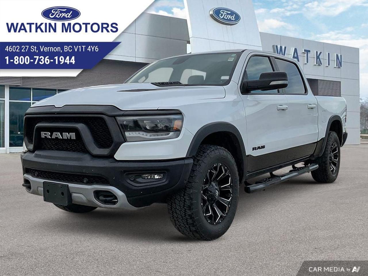 <p>Get ready to conquer any terrain with this head-turning 2019 Ram 1500 Rebel Crew Cab 4x4, proudly offered by Watkin Motors Ford. This bold pickup truck is not just about looks; its built to handle whatever comes its way, whether its a demanding work day or a weekend adventure. With its powerful 5.7L HEMI V8 engine, the Rebel offers a commanding presence on the road and a thrilling driving experience.</p><p>Step inside and youll be greeted by a spacious and comfortable cabin, featuring premium cloth seating, a leather-wrapped steering wheel, and a host of advanced features to keep you connected and entertained. Enjoy the convenience of power windows and locks, cruise control, and a rearview camera for added peace of mind. This Rebel has a well-maintained 105,965km on the odometer, and its signature blacked-out accents, off-road suspension, and 18-inch black painted aluminum wheels will make you stand out from the crowd.</p><p>Ready to experience the thrill of owning a Ram Rebel? Here are five features that will leave you wanting more:</p><ul><li><strong>Bilstein Shock Absorbers:</strong> Designed for superior off-road performance, these shocks will provide a smooth and controlled ride on any terrain.</li><li><strong>Hemi V8 Engine with FuelSaver MDS:</strong> Enjoy powerful acceleration and impressive fuel efficiency with this iconic engine.</li><li><strong>Black Dual Exhaust Tips:</strong> This sleek design adds a touch of aggression to the Rebels powerful presence.</li><li><strong>Off-Road Suspension:</strong> Conquer any obstacle with confidence, thanks to this specialized suspension system.</li><li><strong>Black Painted Aluminum Wheels:</strong> This distinctive design completes the Rebels commanding appearance and complements its off-road capabilities.</li></ul><p><em>Powered by AutoIntelligence™ AI</em></p>