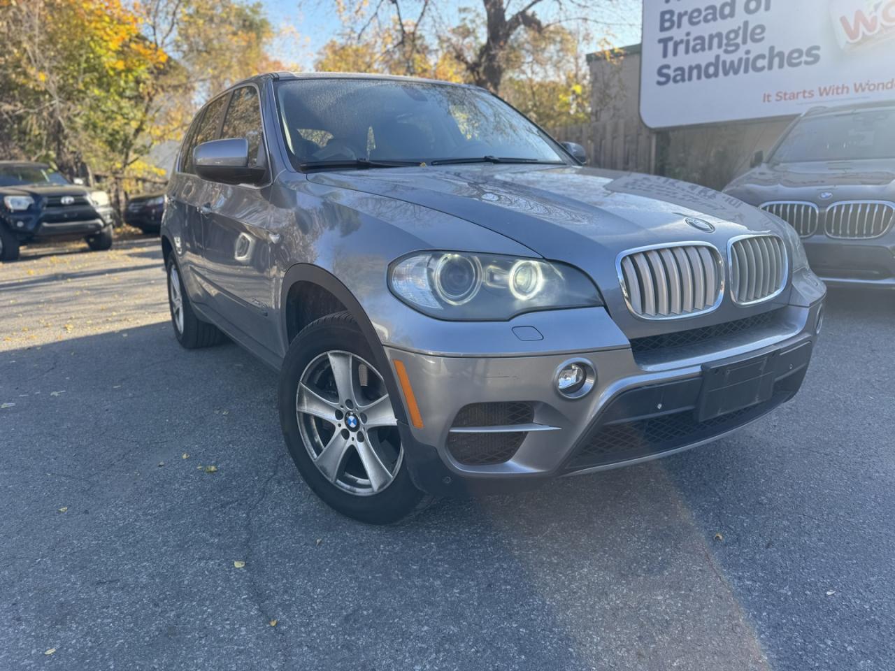 <div><strong>For Sale: 2011 BMW X5 xDrive50i AWD  Sold with Safety Certification</strong></div><br /><div><strong>Price:</strong> $8,750 + tax & licensing<br><strong>Mileage:</strong> 194,000 kilometers</div><br /><div><strong>Purchase Options:</strong></div><ul><li><p><strong>Financing Available for Everyone:</strong> At Garage Plus Auto, we offer flexible financing options for all credit situations. Whether you have good credit, bad credit, or no credit, we can help you secure the best possible financing to fit your budget. We work with multiple lenders to ensure competitive rates and terms.</p></li><li><p><strong>Buy with Confidence:</strong> We sell vehicles via phone call for your convenience.</p></li><li><p><strong>Virtual Showings:</strong> We can show you the car via video call, allowing you to see every detail from anywhere.</p></li><li><p><strong>Nationwide Delivery:</strong> We offer delivery anywhere in Canada, right to your door.</p></li></ul><hr /><br /><div><strong>Features:</strong></div><ul><li><strong>Make:</strong> BMW</li><li><strong>Model:</strong> X5 xDrive50i</li><li><strong>Year:</strong> 2011</li><li><strong>Mileage:</strong> 194,000 kilometers</li><li><strong>Price:</strong> $8,750 + tax & licensing</li><li><strong>Safety Certification:</strong> Included</li><li><strong>Engine:</strong> 8-cylinder, powerful and smooth performance</li><li><strong>Drivetrain:</strong> All-Wheel Drive (AWD)</li><li><strong>Heated & Vented Leather Seats:</strong> Comfort in all weather</li><li><strong>Heated Steering Wheel:</strong> Added comfort for colder days</li><li><strong>Panoramic Roof:</strong> Enhanced view and natural light</li><li><strong>Navigation System:</strong> Convenient and easy route guidance</li><li><strong>Keyless Entry & Push Start Button:</strong> Modern convenience</li><li><strong>Rear A/C:</strong> Extra comfort for passengers in the back</li><li><strong>Winter Tires Included:</strong> Ready for all seasonal conditions</li></ul><hr /><br /><div><strong>Description:</strong><br>For sale is a <strong>2011 BMW X5 xDrive50i AWD</strong> with <strong>194,000 kilometers</strong>, priced at <strong>$8,750</strong> plus tax and licensing. This premium SUV combines luxury, power, and versatility. Equipped with an <strong>8-cylinder engine</strong> and <strong>all-wheel drive</strong>, its designed for a smooth yet powerful driving experience.</div><br /><div>The <strong>heated and vented leather seats</strong>, <strong>heated steering wheel</strong>, and <strong>rear A/C</strong> offer comfort in every season, while the <strong>panoramic roof</strong> adds an open-air feel. Modern conveniences like <strong>keyless entry</strong>, a <strong>push start button</strong>, and <strong>navigation</strong> make every drive enjoyable. Plus, it comes equipped with <strong>winter tires</strong>, making it fully prepared for Canadian winters.</div><hr /><br /><div>For more information or to schedule a test drive, please contact us:</div><br /><div><strong>Location:</strong><br>Garage Plus Auto<br>1201 Bank Street<br>Ottawa, ON K1S 3X7<br>Canada</div><br /><div><strong>Website:</strong> garageplusautocentre.com</div>