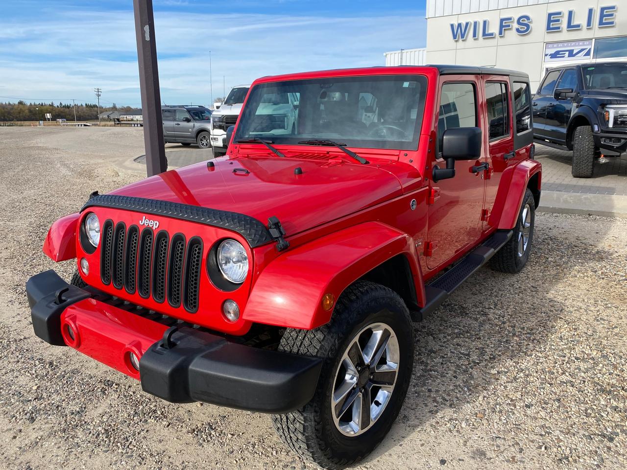 <p>2017 Jeep Wrangler Sahara Unlimited, red exterior, 73,000 kms, removable hard top roof, 4 doors.  Call us to schedule a test drive!</p>