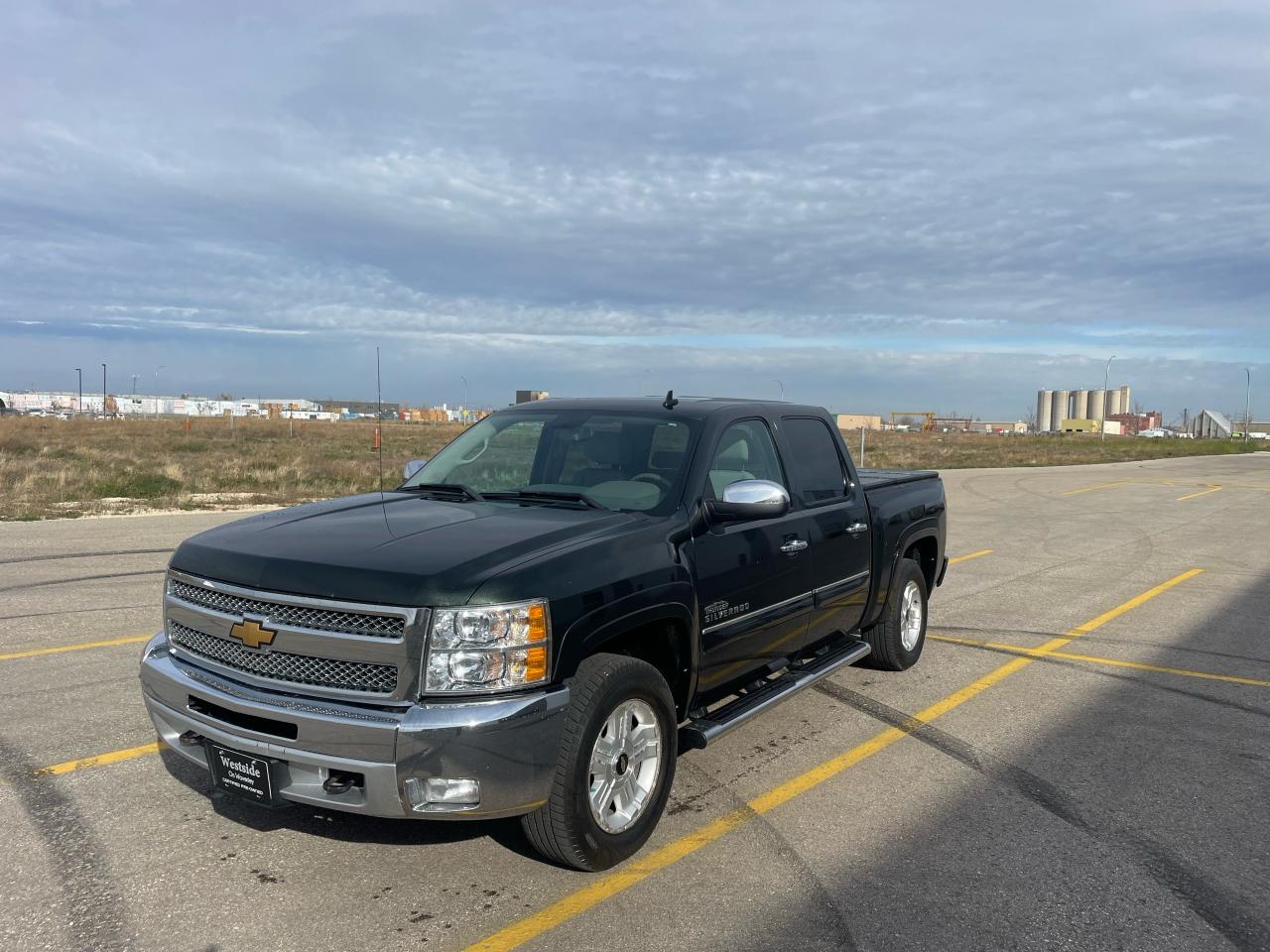 <p>Looking for a reliable and capable pickup truck? Look no further than this 2013 Chevrolet Silverado 1500 LT, available now at Westside Sales. This green beauty packs a powerful 5.3L 8-cylinder engine paired with a smooth-shifting automatic transmission, providing ample power for any task. Its a flex fuel vehicle, so you have the option to choose between gasoline and E85 for added fuel flexibility. With its 4-wheel drive system, this Silverado can handle any weather condition and tackle tough terrain with ease. The spacious interior features comfortable grey cloth seats, a folding rear seat, and plenty of cargo space in the bed, making it perfect for both work and play.</p><p>This Silverado is packed with features to enhance your driving experience, including air conditioning, cruise control, power windows, power locks, and tilt steering wheel. Hard folding Tonneau cover and the keyless entry and security system provide peace of mind. With a 193,000km odometer reading, this truck has plenty of life left in it, making it an excellent value for the price.</p><p>Here are five of the Silverados most desirable features:</p><ol><li><strong>Powerful 5.3L 8-Cylinder Engine:</strong> Provides ample power and torque for hauling and towing.</li><li><strong>4-Wheel Drive:</strong> Conquer any terrain and weather condition with confidence.</li><li><strong>Flex Fuel Capability:</strong> Save money at the pump with the option to use E85 fuel.</li><li><strong>Spacious Cab and Cargo Bed:</strong> Offers ample room for passengers and gear.</li><li><strong>Keyless Entry & Security System:</strong> Provides added security and convenience.</li></ol><p>Come visit Westside Sales today for a test drive and experience the reliability and capability of this 2013 Chevrolet Silverado 1500 LT firsthand. <!-- [if gte mso 9]><xml><br />
 <o:OfficeDocumentSettings><br />
  <o:AllowPNG/><br />
 </o:OfficeDocumentSettings><br />
</xml><![endif]--><!-- [if gte mso 9]><xml><br />
 <w:WordDocument><br />
  <w:View>Normal</w:View><br />
  <w:Zoom>0</w:Zoom><br />
  <w:TrackMoves/><br />
  <w:TrackFormatting/><br />
  <w:PunctuationKerning/><br />
  <w:ValidateAgainstSchemas/><br />
  <w:SaveIfXMLInvalid>false</w:SaveIfXMLInvalid><br />
  <w:IgnoreMixedContent>false</w:IgnoreMixedContent><br />
  <w:AlwaysShowPlaceholderText>false</w:AlwaysShowPlaceholderText><br />
  <w:DoNotPromoteQF/><br />
  <w:LidThemeOther>EN-US</w:LidThemeOther><br />
  <w:LidThemeAsian>X-NONE</w:LidThemeAsian><br />
  <w:LidThemeComplexScript>X-NONE</w:LidThemeComplexScript><br />
  <w:Compatibility><br />
   <w:BreakWrappedTables/><br />
   <w:SnapToGridInCell/><br />
   <w:WrapTextWithPunct/><br />
   <w:UseAsianBreakRules/><br />
   <w:DontGrowAutofit/><br />
   <w:SplitPgBreakAndParaMark/><br />
   <w:EnableOpenTypeKerning/><br />
   <w:DontFlipMirrorIndents/><br />
   <w:OverrideTableStyleHps/><br />
  </w:Compatibility><br />
  <m:mathPr><br />
   <m:mathFont m:val=Cambria Math/><br />
   <m:brkBin m:val=before/><br />
   <m:brkBinSub m:val=--/><br />
   <m:smallFrac m:val=off/><br />
   <m:dispDef/><br />
   <m:lMargin m:val=0/><br />
   <m:rMargin m:val=0/><br />
   <m:defJc m:val=centerGroup/><br />
   <m:wrapIndent m:val=1440/><br />
   <m:intLim m:val=subSup/><br />
   <m:naryLim m:val=undOvr/><br />
  </m:mathPr></w:WordDocument><br />
</xml><![endif]--><!-- [if gte mso 9]><xml><br />
 <w:LatentStyles DefLockedState=false DefUnhideWhenUsed=false<br />
  DefSemiHidden=false DefQFormat=false DefPriority=99<br />
  LatentStyleCount=376><br />
  <w:LsdException Locked=false Priority=0 QFormat=true Name=Normal/><br />
  <w:LsdException Locked=false Priority=9 QFormat=true Name=heading 1/><br />
  <w:LsdException Locked=false Priority=9 SemiHidden=true<br />
   UnhideWhenUsed=true QFormat=true Name=heading 2/><br />
  <w:LsdException Locked=false Priority=9 SemiHidden=true<br />
   UnhideWhenUsed=true QFormat=true Name=heading 3/><br />
  <w:LsdException Locked=false Priority=9 SemiHidden=true<br />
   UnhideWhenUsed=true QFormat=true Name=heading 4/><br />
  <w:LsdException Locked=false Priority=9 SemiHidden=true<br />
   UnhideWhenUsed=true QFormat=true Name=heading 5/><br />
  <w:LsdException Locked=false Priority=9 SemiHidden=true<br />
   UnhideWhenUsed=true QFormat=true Name=heading 6/><br />
  <w:LsdException Locked=false Priority=9 SemiHidden=true<br />
   UnhideWhenUsed=true QFormat=true Name=heading 7/><br />
  <w:LsdException Locked=false Priority=9 SemiHidden=true<br />
   UnhideWhenUsed=true QFormat=true Name=heading 8/><br />
  <w:LsdException Locked=false Priority=9 SemiHidden=true<br />
   UnhideWhenUsed=true QFormat=true Name=heading 9/><br />
  <w:LsdException Locked=false SemiHidden=true UnhideWhenUsed=true<br />
   Name=index 1/><br />
  <w:LsdException Locked=false SemiHidden=true UnhideWhenUsed=true<br />
   Name=index 2/><br />
  <w:LsdException Locked=false SemiHidden=true UnhideWhenUsed=true<br />
   Name=index 3/><br />
  <w:LsdException Locked=false SemiHidden=true UnhideWhenUsed=true<br />
   Name=index 4/><br />
  <w:LsdException Locked=false SemiHidden=true UnhideWhenUsed=true<br />
   Name=index 5/><br />
  <w:LsdException Locked=false SemiHidden=true UnhideWhenUsed=true<br />
   Name=index 6/><br />
  <w:LsdException Locked=false SemiHidden=true UnhideWhenUsed=true<br />
   Name=index 7/><br />
  <w:LsdException Locked=false SemiHidden=true UnhideWhenUsed=true<br />
   Name=index 8/><br />
  <w:LsdException Locked=false SemiHidden=true UnhideWhenUsed=true<br />
   Name=index 9/><br />
  <w:LsdException Locked=false Priority=39 SemiHidden=true<br />
   UnhideWhenUsed=true Name=toc 1/><br />
  <w:LsdException Locked=false Priority=39 SemiHidden=true<br />
   UnhideWhenUsed=true Name=toc 2/><br />
  <w:LsdException Locked=false Priority=39 SemiHidden=true<br />
   UnhideWhenUsed=true Name=toc 3/><br />
  <w:LsdException Locked=false Priority=39 SemiHidden=true<br />
   UnhideWhenUsed=true Name=toc 4/><br />
  <w:LsdException Locked=false Priority=39 SemiHidden=true<br />
   UnhideWhenUsed=true Name=toc 5/><br />
  <w:LsdException Locked=false Priority=39 SemiHidden=true<br />
   UnhideWhenUsed=true Name=toc 6/><br />
  <w:LsdException Locked=false Priority=39 SemiHidden=true<br />
   UnhideWhenUsed=true Name=toc 7/><br />
  <w:LsdException Locked=false Priority=39 SemiHidden=true<br />
   UnhideWhenUsed=true Name=toc 8/><br />
  <w:LsdException Locked=false Priority=39 SemiHidden=true<br />
   UnhideWhenUsed=true Name=toc 9/><br />
  <w:LsdException Locked=false SemiHidden=true UnhideWhenUsed=true<br />
   Name=Normal Indent/><br />
  <w:LsdException Locked=false SemiHidden=true UnhideWhenUsed=true<br />
   Name=footnote text/><br />
  <w:LsdException Locked=false SemiHidden=true UnhideWhenUsed=true<br />
   Name=annotation text/><br />
  <w:LsdException Locked=false SemiHidden=true UnhideWhenUsed=true<br />
   Name=header/><br />
  <w:LsdException Locked=false SemiHidden=true UnhideWhenUsed=true<br />
   Name=footer/><br />
  <w:LsdException Locked=false SemiHidden=true UnhideWhenUsed=true<br />
   Name=index heading/><br />
  <w:LsdException Locked=false Priority=35 SemiHidden=true<br />
   UnhideWhenUsed=true QFormat=true Name=caption/><br />
  <w:LsdException Locked=false SemiHidden=true UnhideWhenUsed=true<br />
   Name=table of figures/><br />
  <w:LsdException Locked=false SemiHidden=true UnhideWhenUsed=true<br />
   Name=envelope address/><br />
  <w:LsdException Locked=false SemiHidden=true UnhideWhenUsed=true<br />
   Name=envelope return/><br />
  <w:LsdException Locked=false SemiHidden=true UnhideWhenUsed=true<br />
   Name=footnote reference/><br />
  <w:LsdException Locked=false SemiHidden=true UnhideWhenUsed=true<br />
   Name=annotation reference/><br />
  <w:LsdException Locked=false SemiHidden=true UnhideWhenUsed=true<br />
   Name=line number/><br />
  <w:LsdException Locked=false SemiHidden=true UnhideWhenUsed=true<br />
   Name=page number/><br />
  <w:LsdException Locked=false SemiHidden=true UnhideWhenUsed=true<br />
   Name=endnote reference/><br />
  <w:LsdException Locked=false SemiHidden=true UnhideWhenUsed=true<br />
   Name=endnote text/><br />
  <w:LsdException Locked=false SemiHidden=true UnhideWhenUsed=true<br />
   Name=table of authorities/><br />
  <w:LsdException Locked=false SemiHidden=true UnhideWhenUsed=true<br />
   Name=macro/><br />
  <w:LsdException Locked=false SemiHidden=true UnhideWhenUsed=true<br />
   Name=toa heading/><br />
  <w:LsdException Locked=false SemiHidden=true UnhideWhenUsed=true<br />
   Name=List/><br />
  <w:LsdException Locked=false SemiHidden=true UnhideWhenUsed=true<br />
   Name=List Bullet/><br />
  <w:LsdException Locked=false SemiHidden=true UnhideWhenUsed=true<br />
   Name=List Number/><br />
  <w:LsdException Locked=false SemiHidden=true UnhideWhenUsed=true<br />
   Name=List 2/><br />
  <w:LsdException Locked=false SemiHidden=true UnhideWhenUsed=true<br />
   Name=List 3/><br />
  <w:LsdException Locked=false SemiHidden=true UnhideWhenUsed=true<br />
   Name=List 4/><br />
  <w:LsdException Locked=false SemiHidden=true UnhideWhenUsed=true<br />
   Name=List 5/><br />
  <w:LsdException Locked=false SemiHidden=true UnhideWhenUsed=true<br />
   Name=List Bullet 2/><br />
  <w:LsdException Locked=false SemiHidden=true UnhideWhenUsed=true<br />
   Name=List Bullet 3/><br />
  <w:LsdException Locked=false SemiHidden=true UnhideWhenUsed=true<br />
   Name=List Bullet 4/><br />
  <w:LsdException Locked=false SemiHidden=true UnhideWhenUsed=true<br />
   Name=List Bullet 5/><br />
  <w:LsdException Locked=false SemiHidden=true UnhideWhenUsed=true<br />
   Name=List Number 2/><br />
  <w:LsdException Locked=false SemiHidden=true UnhideWhenUsed=true<br />
   Name=List Number 3/><br />
  <w:LsdException Locked=false SemiHidden=true UnhideWhenUsed=true<br />
   Name=List Number 4/><br />
  <w:LsdException Locked=false SemiHidden=true UnhideWhenUsed=true<br />
   Name=List Number 5/><br />
  <w:LsdException Locked=false Priority=10 QFormat=true Name=Title/><br />
  <w:LsdException Locked=false SemiHidden=true UnhideWhenUsed=true<br />
   Name=Closing/><br />
  <w:LsdException Locked=false SemiHidden=true UnhideWhenUsed=true<br />
   Name=Signature/><br />
  <w:LsdException Locked=false Priority=1 SemiHidden=true<br />
   UnhideWhenUsed=true Name=Default Paragraph Font/><br />
  <w:LsdException Locked=false SemiHidden=true UnhideWhenUsed=true<br />
   Name=Body Text/><br />
  <w:LsdException Locked=false SemiHidden=true UnhideWhenUsed=true<br />
   Name=Body Text Indent/><br />
  <w:LsdException Locked=false SemiHidden=true UnhideWhenUsed=true<br />
   Name=List Continue/><br />
  <w:LsdException Locked=false SemiHidden=true UnhideWhenUsed=true<br />
   Name=List Continue 2/><br />
  <w:LsdException Locked=false SemiHidden=true UnhideWhenUsed=true<br />
   Name=List Continue 3/><br />
  <w:LsdException Locked=false SemiHidden=true UnhideWhenUsed=true<br />
   Name=List Continue 4/><br />
  <w:LsdException Locked=false SemiHidden=true UnhideWhenUsed=true<br />
   Name=List Continue 5/><br />
  <w:LsdException Locked=false SemiHidden=true UnhideWhenUsed=true<br />
   Name=Message Header/><br />
  <w:LsdException Locked=false Priority=11 QFormat=true Name=Subtitle/><br />
  <w:LsdException Locked=false SemiHidden=true UnhideWhenUsed=true<br />
   Name=Salutation/><br />
  <w:LsdException Locked=false SemiHidden=true UnhideWhenUsed=true<br />
   Name=Date/><br />
  <w:LsdException Locked=false SemiHidden=true UnhideWhenUsed=true<br />
   Name=Body Text First Indent/><br />
  <w:LsdException Locked=false SemiHidden=true UnhideWhenUsed=true<br />
   Name=Body Text First Indent 2/><br />
  <w:LsdException Locked=false SemiHidden=true UnhideWhenUsed=true<br />
   Name=Note Heading/><br />
  <w:LsdException Locked=false SemiHidden=true UnhideWhenUsed=true<br />
   Name=Body Text 2/><br />
  <w:LsdException Locked=false SemiHidden=true UnhideWhenUsed=true<br />
   Name=Body Text 3/><br />
  <w:LsdException Locked=false SemiHidden=true UnhideWhenUsed=true<br />
   Name=Body Text Indent 2/><br />
  <w:LsdException Locked=false SemiHidden=true UnhideWhenUsed=true<br />
   Name=Body Text Indent 3/><br />
  <w:LsdException Locked=false SemiHidden=true UnhideWhenUsed=true<br />
   Name=Block Text/><br />
  <w:LsdException Locked=false SemiHidden=true UnhideWhenUsed=true<br />
   Name=Hyperlink/><br />
  <w:LsdException Locked=false SemiHidden=true UnhideWhenUsed=true<br />
   Name=FollowedHyperlink/><br />
  <w:LsdException Locked=false Priority=22 QFormat=true Name=Strong/><br />
  <w:LsdException Locked=false Priority=20 QFormat=true Name=Emphasis/><br />
  <w:LsdException Locked=false SemiHidden=true UnhideWhenUsed=true<br />
   Name=Document Map/><br />
  <w:LsdException Locked=false SemiHidden=true UnhideWhenUsed=true<br />
   Name=Plain Text/><br />
  <w:LsdException Locked=false SemiHidden=true UnhideWhenUsed=true<br />
   Name=E-mail Signature/><br />
  <w:LsdException Locked=false SemiHidden=true UnhideWhenUsed=true<br />
   Name=HTML Top of Form/><br />
  <w:LsdException Locked=false SemiHidden=true UnhideWhenUsed=true<br />
   Name=HTML Bottom of Form/><br />
  <w:LsdException Locked=false SemiHidden=true UnhideWhenUsed=true<br />
   Name=Normal (Web)/><br />
  <w:LsdException Locked=false SemiHidden=true UnhideWhenUsed=true<br />
   Name=HTML Acronym/><br />
  <w:LsdException Locked=false SemiHidden=true UnhideWhenUsed=true<br />
   Name=HTML Address/><br />
  <w:LsdException Locked=false SemiHidden=true UnhideWhenUsed=true<br />
   Name=HTML Cite/><br />
  <w:LsdException Locked=false SemiHidden=true UnhideWhenUsed=true<br />
   Name=HTML Code/><br />
  <w:LsdException Locked=false SemiHidden=true UnhideWhenUsed=true<br />
   Name=HTML Definition/><br />
  <w:LsdException Locked=false SemiHidden=true UnhideWhenUsed=true<br />
   Name=HTML Keyboard/><br />
  <w:LsdException Locked=false SemiHidden=true UnhideWhenUsed=true<br />
   Name=HTML Preformatted/><br />
  <w:LsdException Locked=false SemiHidden=true UnhideWhenUsed=true<br />
   Name=HTML Sample/><br />
  <w:LsdException Locked=false SemiHidden=true UnhideWhenUsed=true<br />
   Name=HTML Typewriter/><br />
  <w:LsdException Locked=false SemiHidden=true UnhideWhenUsed=true<br />
   Name=HTML Variable/><br />
  <w:LsdException Locked=false SemiHidden=true UnhideWhenUsed=true<br />
   Name=Normal Table/><br />
  <w:LsdException Locked=false SemiHidden=true UnhideWhenUsed=true<br />
   Name=annotation subject/><br />
  <w:LsdException Locked=false SemiHidden=true UnhideWhenUsed=true<br />
   Name=No List/><br />
  <w:LsdException Locked=false SemiHidden=true UnhideWhenUsed=true<br />
   Name=Outline List 1/><br />
  <w:LsdException Locked=false SemiHidden=true UnhideWhenUsed=true<br />
   Name=Outline List 2/><br />
  <w:LsdException Locked=false SemiHidden=true UnhideWhenUsed=true<br />
   Name=Outline List 3/><br />
  <w:LsdException Locked=false SemiHidden=true UnhideWhenUsed=true<br />
   Name=Table Simple 1/><br />
  <w:LsdException Locked=false SemiHidden=true UnhideWhenUsed=true<br />
   Name=Table Simple 2/><br />
  <w:LsdException Locked=false SemiHidden=true UnhideWhenUsed=true<br />
   Name=Table Simple 3/><br />
  <w:LsdException Locked=false SemiHidden=true UnhideWhenUsed=true<br />
   Name=Table Classic 1/><br />
  <w:LsdException Locked=false SemiHidden=true UnhideWhenUsed=true<br />
   Name=Table Classic 2/><br />
  <w:LsdException Locked=false SemiHidden=true UnhideWhenUsed=true<br />
   Name=Table Classic 3/><br />
  <w:LsdException Locked=false SemiHidden=true UnhideWhenUsed=true<br />
   Name=Table Classic 4/><br />
  <w:LsdException Locked=false SemiHidden=true UnhideWhenUsed=true<br />
   Name=Table Colorful 1/><br />
  <w:LsdException Locked=false SemiHidden=true UnhideWhenUsed=true<br />
   Name=Table Colorful 2/><br />
  <w:LsdException Locked=false SemiHidden=true UnhideWhenUsed=true<br />
   Name=Table Colorful 3/><br />
  <w:LsdException Locked=false SemiHidden=true UnhideWhenUsed=true<br />
   Name=Table Columns 1/><br />
  <w:LsdException Locked=false SemiHidden=true UnhideWhenUsed=true<br />
   Name=Table Columns 2/><br />
  <w:LsdException Locked=false SemiHidden=true UnhideWhenUsed=true<br />
   Name=Table Columns 3/><br />
  <w:LsdException Locked=false SemiHidden=true UnhideWhenUsed=true<br />
   Name=Table Columns 4/><br />
  <w:LsdException Locked=false SemiHidden=true UnhideWhenUsed=true<br />
   Name=Table Columns 5/><br />
  <w:LsdException Locked=false SemiHidden=true UnhideWhenUsed=true<br />
   Name=Table Grid 1/><br />
  <w:LsdException Locked=false SemiHidden=true UnhideWhenUsed=true<br />
   Name=Table Grid 2/><br />
  <w:LsdException Locked=false SemiHidden=true UnhideWhenUsed=true<br />
   Name=Table Grid 3/><br />
  <w:LsdException Locked=false SemiHidden=true UnhideWhenUsed=true<br />
   Name=Table Grid 4/><br />
  <w:LsdException Locked=false SemiHidden=true UnhideWhenUsed=true<br />
   Name=Table Grid 5/><br />
  <w:LsdException Locked=false SemiHidden=true UnhideWhenUsed=true<br />
   Name=Table Grid 6/><br />
  <w:LsdException Locked=false SemiHidden=true UnhideWhenUsed=true<br />
   Name=Table Grid 7/><br />
  <w:LsdException Locked=false SemiHidden=true UnhideWhenUsed=true<br />
   Name=Table Grid 8/><br />
  <w:LsdException Locked=false SemiHidden=true UnhideWhenUsed=true<br />
   Name=Table List 1/><br />
  <w:LsdException Locked=false SemiHidden=true UnhideWhenUsed=true<br />
   Name=Table List 2/><br />
  <w:LsdException Locked=false SemiHidden=true UnhideWhenUsed=true<br />
   Name=Table List 3/><br />
  <w:LsdException Locked=false SemiHidden=true UnhideWhenUsed=true<br />
   Name=Table List 4/><br />
  <w:LsdException Locked=false SemiHidden=true UnhideWhenUsed=true<br />
   Name=Table List 5/><br />
  <w:LsdException Locked=false SemiHidden=true UnhideWhenUsed=true<br />
   Name=Table List 6/><br />
  <w:LsdException Locked=false SemiHidden=true UnhideWhenUsed=true<br />
   Name=Table List 7/><br />
  <w:LsdException Locked=false SemiHidden=true UnhideWhenUsed=true<br />
   Name=Table List 8/><br />
  <w:LsdException Locked=false SemiHidden=true UnhideWhenUsed=true<br />
   Name=Table 3D effects 1/><br />
  <w:LsdException Locked=false SemiHidden=true UnhideWhenUsed=true<br />
   Name=Table 3D effects 2/><br />
  <w:LsdException Locked=false SemiHidden=true UnhideWhenUsed=true<br />
   Name=Table 3D effects 3/><br />
  <w:LsdException Locked=false SemiHidden=true UnhideWhenUsed=true<br />
   Name=Table Contemporary/><br />
  <w:LsdException Locked=false SemiHidden=true UnhideWhenUsed=true<br />
   Name=Table Elegant/><br />
  <w:LsdException Locked=false SemiHidden=true UnhideWhenUsed=true<br />
   Name=Table Professional/><br />
  <w:LsdException Locked=false SemiHidden=true UnhideWhenUsed=true<br />
   Name=Table Subtle 1/><br />
  <w:LsdException Locked=false SemiHidden=true UnhideWhenUsed=true<br />
   Name=Table Subtle 2/><br />
  <w:LsdException Locked=false SemiHidden=true UnhideWhenUsed=true<br />
   Name=Table Web 1/><br />
  <w:LsdException Locked=false SemiHidden=true UnhideWhenUsed=true<br />
   Name=Table Web 2/><br />
  <w:LsdException Locked=false SemiHidden=true UnhideWhenUsed=true<br />
   Name=Table Web 3/><br />
  <w:LsdException Locked=false SemiHidden=true UnhideWhenUsed=true<br />
   Name=Balloon Text/><br />
  <w:LsdException Locked=false Priority=39 Name=Table Grid/><br />
  <w:LsdException Locked=false SemiHidden=true UnhideWhenUsed=true<br />
   Name=Table Theme/><br />
  <w:LsdException Locked=false SemiHidden=true Name=Placeholder Text/><br />
  <w:LsdException Locked=false Priority=1 QFormat=true Name=No Spacing/><br />
  <w:LsdException Locked=false Priority=60 Name=Light Shading/><br />
  <w:LsdException Locked=false Priority=61 Name=Light List/><br />
  <w:LsdException Locked=false Priority=62 Name=Light Grid/><br />
  <w:LsdException Locked=false Priority=63 Name=Medium Shading 1/><br />
  <w:LsdException Locked=false Priority=64 Name=Medium Shading 2/><br />
  <w:LsdException Locked=false Priority=65 Name=Medium List 1/><br />
  <w:LsdException Locked=false Priority=66 Name=Medium List 2/><br />
  <w:LsdException Locked=false Priority=67 Name=Medium Grid 1/><br />
  <w:LsdException Locked=false Priority=68 Name=Medium Grid 2/><br />
  <w:LsdException Locked=false Priority=69 Name=Medium Grid 3/><br />
  <w:LsdException Locked=false Priority=70 Name=Dark List/><br />
  <w:LsdException Locked=false Priority=71 Name=Colorful Shading/><br />
  <w:LsdException Locked=false Priority=72 Name=Colorful List/><br />
  <w:LsdException Locked=false Priority=73 Name=Colorful Grid/><br />
  <w:LsdException Locked=false Priority=60 Name=Light Shading Accent 1/><br />
  <w:LsdException Locked=false Priority=61 Name=Light List Accent 1/><br />
  <w:LsdException Locked=false Priority=62 Name=Light Grid Accent 1/><br />
  <w:LsdException Locked=false Priority=63 Name=Medium Shading 1 Accent 1/><br />
  <w:LsdException Locked=false Priority=64 Name=Medium Shading 2 Accent 1/><br />
  <w:LsdException Locked=false Priority=65 Name=Medium List 1 Accent 1/><br />
  <w:LsdException Locked=false SemiHidden=true Name=Revision/><br />
  <w:LsdException Locked=false Priority=34 QFormat=true<br />
   Name=List Paragraph/><br />
  <w:LsdException Locked=false Priority=29 QFormat=true Name=Quote/><br />
  <w:LsdException Locked=false Priority=30 QFormat=true<br />
   Name=Intense Quote/><br />
  <w:LsdException Locked=false Priority=66 Name=Medium List 2 Accent 1/><br />
  <w:LsdException Locked=false Priority=67 Name=Medium Grid 1 Accent 1/><br />
  <w:LsdException Locked=false Priority=68 Name=Medium Grid 2 Accent 1/><br />
  <w:LsdException Locked=false Priority=69 Name=Medium Grid 3 Accent 1/><br />
  <w:LsdException Locked=false Priority=70 Name=Dark List Accent 1/><br />
  <w:LsdException Locked=false Priority=71 Name=Colorful Shading Accent 1/><br />
  <w:LsdException Locked=false Priority=72 Name=Colorful List Accent 1/><br />
  <w:LsdException Locked=false Priority=73 Name=Colorful Grid Accent 1/><br />
  <w:LsdException Locked=false Priority=60 Name=Light Shading Accent 2/><br />
  <w:LsdException Locked=false Priority=61 Name=Light List Accent 2/><br />
  <w:LsdException Locked=false Priority=62 Name=Light Grid Accent 2/><br />
  <w:LsdException Locked=false Priority=63 Name=Medium Shading 1 Accent 2/><br />
  <w:LsdException Locked=false Priority=64 Name=Medium Shading 2 Accent 2/><br />
  <w:LsdException Locked=false Priority=65 Name=Medium List 1 Accent 2/><br />
  <w:LsdException Locked=false Priority=66 Name=Medium List 2 Accent 2/><br />
  <w:LsdException Locked=false Priority=67 Name=Medium Grid 1 Accent 2/><br />
  <w:LsdException Locked=false Priority=68 Name=Medium Grid 2 Accent 2/><br />
  <w:LsdException Locked=false Priority=69 Name=Medium Grid 3 Accent 2/><br />
  <w:LsdException Locked=false Priority=70 Name=Dark List Accent 2/><br />
  <w:LsdException Locked=false Priority=71 Name=Colorful Shading Accent 2/><br />
  <w:LsdException Locked=false Priority=72 Name=Colorful List Accent 2/><br />
  <w:LsdException Locked=false Priority=73 Name=Colorful Grid Accent 2/><br />
  <w:LsdException Locked=false Priority=60 Name=Light Shading Accent 3/><br />
  <w:LsdException Locked=false Priority=61 Name=Light List Accent 3/><br />
  <w:LsdException Locked=false Priority=62 Name=Light Grid Accent 3/><br />
  <w:LsdException Locked=false Priority=63 Name=Medium Shading 1 Accent 3/><br />
  <w:LsdException Locked=false Priority=64 Name=Medium Shading 2 Accent 3/><br />
  <w:LsdException Locked=false Priority=65 Name=Medium List 1 Accent 3/><br />
  <w:LsdException Locked=false Priority=66 Name=Medium List 2 Accent 3/><br />
  <w:LsdException Locked=false Priority=67 Name=Medium Grid 1 Accent 3/><br />
  <w:LsdException Locked=false Priority=68 Name=Medium Grid 2 Accent 3/><br />
  <w:LsdException Locked=false Priority=69 Name=Medium Grid 3 Accent 3/><br />
  <w:LsdException Locked=false Priority=70 Name=Dark List Accent 3/><br />
  <w:LsdException Locked=false Priority=71 Name=Colorful Shading Accent 3/><br />
  <w:LsdException Locked=false Priority=72 Name=Colorful List Accent 3/><br />
  <w:LsdException Locked=false Priority=73 Name=Colorful Grid Accent 3/><br />
  <w:LsdException Locked=false Priority=60 Name=Light Shading Accent 4/><br />
  <w:LsdException Locked=false Priority=61 Name=Light List Accent 4/><br />
  <w:LsdException Locked=false Priority=62 Name=Light Grid Accent 4/><br />
  <w:LsdException Locked=false Priority=63 Name=Medium Shading 1 Accent 4/><br />
  <w:LsdException Locked=false Priority=64 Name=Medium Shading 2 Accent 4/><br />
  <w:LsdException Locked=false Priority=65 Name=Medium List 1 Accent 4/><br />
  <w:LsdException Locked=false Priority=66 Name=Medium List 2 Accent 4/><br />
  <w:LsdException Locked=false Priority=67 Name=Medium Grid 1 Accent 4/><br />
  <w:LsdException Locked=false Priority=68 Name=Medium Grid 2 Accent 4/><br />
  <w:LsdException Locked=false Priority=69 Name=Medium Grid 3 Accent 4/><br />
  <w:LsdException Locked=false Priority=70 Name=Dark List Accent 4/><br />
  <w:LsdException Locked=false Priority=71 Name=Colorful Shading Accent 4/><br />
  <w:LsdException Locked=false Priority=72 Name=Colorful List Accent 4/><br />
  <w:LsdException Locked=false Priority=73 Name=Colorful Grid Accent 4/><br />
  <w:LsdException Locked=false Priority=60 Name=Light Shading Accent 5/><br />
  <w:LsdException Locked=false Priority=61 Name=Light List Accent 5/><br />
  <w:LsdException Locked=false Priority=62 Name=Light Grid Accent 5/><br />
  <w:LsdException Locked=false Priority=63 Name=Medium Shading 1 Accent 5/><br />
  <w:LsdException Locked=false Priority=64 Name=Medium Shading 2 Accent 5/><br />
  <w:LsdException Locked=false Priority=65 Name=Medium List 1 Accent 5/><br />
  <w:LsdException Locked=false Priority=66 Name=Medium List 2 Accent 5/><br />
  <w:LsdException Locked=false Priority=67 Name=Medium Grid 1 Accent 5/><br />
  <w:LsdException Locked=false Priority=68 Name=Medium Grid 2 Accent 5/><br />
  <w:LsdException Locked=false Priority=69 Name=Medium Grid 3 Accent 5/><br />
  <w:LsdException Locked=false Priority=70 Name=Dark List Accent 5/><br />
  <w:LsdException Locked=false Priority=71 Name=Colorful Shading Accent 5/><br />
  <w:LsdException Locked=false Priority=72 Name=Colorful List Accent 5/><br />
  <w:LsdException Locked=false Priority=73 Name=Colorful Grid Accent 5/><br />
  <w:LsdException Locked=false Priority=60 Name=Light Shading Accent 6/><br />
  <w:LsdException Locked=false Priority=61 Name=Light List Accent 6/><br />
  <w:LsdException Locked=false Priority=62 Name=Light Grid Accent 6/><br />
  <w:LsdException Locked=false Priority=63 Name=Medium Shading 1 Accent 6/><br />
  <w:LsdException Locked=false Priority=64 Name=Medium Shading 2 Accent 6/><br />
  <w:LsdException Locked=false Priority=65 Name=Medium List 1 Accent 6/><br />
  <w:LsdException Locked=false Priority=66 Name=Medium List 2 Accent 6/><br />
  <w:LsdException Locked=false Priority=67 Name=Medium Grid 1 Accent 6/><br />
  <w:LsdException Locked=false Priority=68 Name=Medium Grid 2 Accent 6/><br />
  <w:LsdException Locked=false Priority=69 Name=Medium Grid 3 Accent 6/><br />
  <w:LsdException Locked=false Priority=70 Name=Dark List Accent 6/><br />
  <w:LsdException Locked=false Priority=71 Name=Colorful Shading Accent 6/><br />
  <w:LsdException Locked=false Priority=72 Name=Colorful List Accent 6/><br />
  <w:LsdException Locked=false Priority=73 Name=Colorful Grid Accent 6/><br />
  <w:LsdException Locked=false Priority=19 QFormat=true<br />
   Name=Subtle Emphasis/><br />
  <w:LsdException Locked=false Priority=21 QFormat=true<br />
   Name=Intense Emphasis/><br />
  <w:LsdException Locked=false Priority=31 QFormat=true<br />
   Name=Subtle Reference/><br />
  <w:LsdException Locked=false Priority=32 QFormat=true<br />
   Name=Intense Reference/><br />
  <w:LsdException Locked=false Priority=33 QFormat=true Name=Book Title/><br />
  <w:LsdException Locked=false Priority=37 SemiHidden=true<br />
   UnhideWhenUsed=true Name=Bibliography/><br />
  <w:LsdException Locked=false Priority=39 SemiHidden=true<br />
   UnhideWhenUsed=true QFormat=true Name=TOC Heading/><br />
  <w:LsdException Locked=false Priority=41 Name=Plain Table 1/><br />
  <w:LsdException Locked=false Priority=42 Name=Plain Table 2/><br />
  <w:LsdException Locked=false Priority=43 Name=Plain Table 3/><br />
  <w:LsdException Locked=false Priority=44 Name=Plain Table 4/><br />
  <w:LsdException Locked=false Priority=45 Name=Plain Table 5/><br />
  <w:LsdException Locked=false Priority=40 Name=Grid Table Light/><br />
  <w:LsdException Locked=false Priority=46 Name=Grid Table 1 Light/><br />
  <w:LsdException Locked=false Priority=47 Name=Grid Table 2/><br />
  <w:LsdException Locked=false Priority=48 Name=Grid Table 3/><br />
  <w:LsdException Locked=false Priority=49 Name=Grid Table 4/><br />
  <w:LsdException Locked=false Priority=50 Name=Grid Table 5 Dark/><br />
  <w:LsdException Locked=false Priority=51 Name=Grid Table 6 Colorful/><br />
  <w:LsdException Locked=false Priority=52 Name=Grid Table 7 Colorful/><br />
  <w:LsdException Locked=false Priority=46<br />
   Name=Grid Table 1 Light Accent 1/><br />
  <w:LsdException Locked=false Priority=47 Name=Grid Table 2 Accent 1/><br />
  <w:LsdException Locked=false Priority=48 Name=Grid Table 3 Accent 1/><br />
  <w:LsdException Locked=false Priority=49 Name=Grid Table 4 Accent 1/><br />
  <w:LsdException Locked=false Priority=50 Name=Grid Table 5 Dark Accent 1/><br />
  <w:LsdException Locked=false Priority=51<br />
   Name=Grid Table 6 Colorful Accent 1/><br />
  <w:LsdException Locked=false Priority=52<br />
   Name=Grid Table 7 Colorful Accent 1/><br />
  <w:LsdException Locked=false Priority=46<br />
   Name=Grid Table 1 Light Accent 2/><br />
  <w:LsdException Locked=false Priority=47 Name=Grid Table 2 Accent 2/><br />
  <w:LsdException Locked=false Priority=48 Name=Grid Table 3 Accent 2/><br />
  <w:LsdException Locked=false Priority=49 Name=Grid Table 4 Accent 2/><br />
  <w:LsdException Locked=false Priority=50 Name=Grid Table 5 Dark Accent 2/><br />
  <w:LsdException Locked=false Priority=51<br />
   Name=Grid Table 6 Colorful Accent 2/><br />
  <w:LsdException Locked=false Priority=52<br />
   Name=Grid Table 7 Colorful Accent 2/><br />
  <w:LsdException Locked=false Priority=46<br />
   Name=Grid Table 1 Light Accent 3/><br />
  <w:LsdException Locked=false Priority=47 Name=Grid Table 2 Accent 3/><br />
  <w:LsdException Locked=false Priority=48 Name=Grid Table 3 Accent 3/><br />
  <w:LsdException Locked=false Priority=49 Name=Grid Table 4 Accent 3/><br />
  <w:LsdException Locked=false Priority=50 Name=Grid Table 5 Dark Accent 3/><br />
  <w:LsdException Locked=false Priority=51<br />
   Name=Grid Table 6 Colorful Accent 3/><br />
  <w:LsdException Locked=false Priority=52<br />
   Name=Grid Table 7 Colorful Accent 3/><br />
  <w:LsdException Locked=false Priority=46<br />
   Name=Grid Table 1 Light Accent 4/><br />
  <w:LsdException Locked=false Priority=47 Name=Grid Table 2 Accent 4/><br />
  <w:LsdException Locked=false Priority=48 Name=Grid Table 3 Accent 4/><br />
  <w:LsdException Locked=false Priority=49 Name=Grid Table 4 Accent 4/><br />
  <w:LsdException Locked=false Priority=50 Name=Grid Table 5 Dark Accent 4/><br />
  <w:LsdException Locked=false Priority=51<br />
   Name=Grid Table 6 Colorful Accent 4/><br />
  <w:LsdException Locked=false Priority=52<br />
   Name=Grid Table 7 Colorful Accent 4/><br />
  <w:LsdException Locked=false Priority=46<br />
   Name=Grid Table 1 Light Accent 5/><br />
  <w:LsdException Locked=false Priority=47 Name=Grid Table 2 Accent 5/><br />
  <w:LsdException Locked=false Priority=48 Name=Grid Table 3 Accent 5/><br />
  <w:LsdException Locked=false Priority=49 Name=Grid Table 4 Accent 5/><br />
  <w:LsdException Locked=false Priority=50 Name=Grid Table 5 Dark Accent 5/><br />
  <w:LsdException Locked=false Priority=51<br />
   Name=Grid Table 6 Colorful Accent 5/><br />
  <w:LsdException Locked=false Priority=52<br />
   Name=Grid Table 7 Colorful Accent 5/><br />
  <w:LsdException Locked=false Priority=46<br />
   Name=Grid Table 1 Light Accent 6/><br />
  <w:LsdException Locked=false Priority=47 Name=Grid Table 2 Accent 6/><br />
  <w:LsdException Locked=false Priority=48 Name=Grid Table 3 Accent 6/><br />
  <w:LsdException Locked=false Priority=49 Name=Grid Table 4 Accent 6/><br />
  <w:LsdException Locked=false Priority=50 Name=Grid Table 5 Dark Accent 6/><br />
  <w:LsdException Locked=false Priority=51<br />
   Name=Grid Table 6 Colorful Accent 6/><br />
  <w:LsdException Locked=false Priority=52<br />
   Name=Grid Table 7 Colorful Accent 6/><br />
  <w:LsdException Locked=false Priority=46 Name=List Table 1 Light/><br />
  <w:LsdException Locked=false Priority=47 Name=List Table 2/><br />
  <w:LsdException Locked=false Priority=48 Name=List Table 3/><br />
  <w:LsdException Locked=false Priority=49 Name=List Table 4/><br />
  <w:LsdException Locked=false Priority=50 Name=List Table 5 Dark/><br />
  <w:LsdException Locked=false Priority=51 Name=List Table 6 Colorful/><br />
  <w:LsdException Locked=false Priority=52 Name=List Table 7 Colorful/><br />
  <w:LsdException Locked=false Priority=46<br />
   Name=List Table 1 Light Accent 1/><br />
  <w:LsdException Locked=false Priority=47 Name=List Table 2 Accent 1/><br />
  <w:LsdException Locked=false Priority=48 Name=List Table 3 Accent 1/><br />
  <w:LsdException Locked=false Priority=49 Name=List Table 4 Accent 1/><br />
  <w:LsdException Locked=false Priority=50 Name=List Table 5 Dark Accent 1/><br />
  <w:LsdException Locked=false Priority=51<br />
   Name=List Table 6 Colorful Accent 1/><br />
  <w:LsdException Locked=false Priority=52<br />
   Name=List Table 7 Colorful Accent 1/><br />
  <w:LsdException Locked=false Priority=46<br />
   Name=List Table 1 Light Accent 2/><br />
  <w:LsdException Locked=false Priority=47 Name=List Table 2 Accent 2/><br />
  <w:LsdException Locked=false Priority=48 Name=List Table 3 Accent 2/><br />
  <w:LsdException Locked=false Priority=49 Name=List Table 4 Accent 2/><br />
  <w:LsdException Locked=false Priority=50 Name=List Table 5 Dark Accent 2/><br />
  <w:LsdException Locked=false Priority=51<br />
   Name=List Table 6 Colorful Accent 2/><br />
  <w:LsdException Locked=false Priority=52<br />
   Name=List Table 7 Colorful Accent 2/><br />
  <w:LsdException Locked=false Priority=46<br />
   Name=List Table 1 Light Accent 3/><br />
  <w:LsdException Locked=false Priority=47 Name=List Table 2 Accent 3/><br />
  <w:LsdException Locked=false Priority=48 Name=List Table 3 Accent 3/><br />
  <w:LsdException Locked=false Priority=49 Name=List Table 4 Accent 3/><br />
  <w:LsdException Locked=false Priority=50 Name=List Table 5 Dark Accent 3/><br />
  <w:LsdException Locked=false Priority=51<br />
   Name=List Table 6 Colorful Accent 3/><br />
  <w:LsdException Locked=false Priority=52<br />
   Name=List Table 7 Colorful Accent 3/><br />
  <w:LsdException Locked=false Priority=46<br />
   Name=List Table 1 Light Accent 4/><br />
  <w:LsdException Locked=false Priority=47 Name=List Table 2 Accent 4/><br />
  <w:LsdException Locked=false Priority=48 Name=List Table 3 Accent 4/><br />
  <w:LsdException Locked=false Priority=49 Name=List Table 4 Accent 4/><br />
  <w:LsdException Locked=false Priority=50 Name=List Table 5 Dark Accent 4/><br />
  <w:LsdException Locked=false Priority=51<br />
   Name=List Table 6 Colorful Accent 4/><br />
  <w:LsdException Locked=false Priority=52<br />
   Name=List Table 7 Colorful Accent 4/><br />
  <w:LsdException Locked=false Priority=46<br />
   Name=List Table 1 Light Accent 5/><br />
  <w:LsdException Locked=false Priority=47 Name=List Table 2 Accent 5/><br />
  <w:LsdException Locked=false Priority=48 Name=List Table 3 Accent 5/><br />
  <w:LsdException Locked=false Priority=49 Name=List Table 4 Accent 5/><br />
  <w:LsdException Locked=false Priority=50 Name=List Table 5 Dark Accent 5/><br />
  <w:LsdException Locked=false Priority=51<br />
   Name=List Table 6 Colorful Accent 5/><br />
  <w:LsdException Locked=false Priority=52<br />
   Name=List Table 7 Colorful Accent 5/><br />
  <w:LsdException Locked=false Priority=46<br />
   Name=List Table 1 Light Accent 6/><br />
  <w:LsdException Locked=false Priority=47 Name=List Table 2 Accent 6/><br />
  <w:LsdException Locked=false Priority=48 Name=List Table 3 Accent 6/><br />
  <w:LsdException Locked=false Priority=49 Name=List Table 4 Accent 6/><br />
  <w:LsdException Locked=false Priority=50 Name=List Table 5 Dark Accent 6/><br />
  <w:LsdException Locked=false Priority=51<br />
   Name=List Table 6 Colorful Accent 6/><br />
  <w:LsdException Locked=false Priority=52<br />
   Name=List Table 7 Colorful Accent 6/><br />
  <w:LsdException Locked=false SemiHidden=true UnhideWhenUsed=true<br />
   Name=Mention/><br />
  <w:LsdException Locked=false SemiHidden=true UnhideWhenUsed=true<br />
   Name=Smart Hyperlink/><br />
  <w:LsdException Locked=false SemiHidden=true UnhideWhenUsed=true<br />
   Name=Hashtag/><br />
  <w:LsdException Locked=false SemiHidden=true UnhideWhenUsed=true<br />
   Name=Unresolved Mention/><br />
  <w:LsdException Locked=false SemiHidden=true UnhideWhenUsed=true<br />
   Name=Smart Link/><br />
 </w:LatentStyles><br />
</xml><![endif]--><!-- [if gte mso 10]><br />
<style><br />
 /* Style Definitions */<br />
 table.MsoNormalTable<br />
	{mso-style-name:Table Normal;<br />
	mso-tstyle-rowband-size:0;<br />
	mso-tstyle-colband-size:0;<br />
	mso-style-noshow:yes;<br />
	mso-style-priority:99;<br />
	mso-style-parent:;<br />
	mso-padding-alt:0in 5.4pt 0in 5.4pt;<br />
	mso-para-margin-top:0in;<br />
	mso-para-margin-right:0in;<br />
	mso-para-margin-bottom:8.0pt;<br />
	mso-para-margin-left:0in;<br />
	line-height:107%;<br />
	mso-pagination:widow-orphan;<br />
	font-size:11.0pt;<br />
	font-family:Calibri,sans-serif;<br />
	mso-ascii-font-family:Calibri;<br />
	mso-ascii-theme-font:minor-latin;<br />
	mso-hansi-font-family:Calibri;<br />
	mso-hansi-theme-font:minor-latin;<br />
	mso-bidi-font-family:Times New Roman;<br />
	mso-bidi-theme-font:minor-bidi;<br />
	mso-font-kerning:1.0pt;<br />
	mso-ligatures:standardcontextual;}<br />
</style><br />
<![endif]--> 1461 Waverley Street 204 488 3793. All vehicles safety certified and serviced, licensed technician on staff . Buy with confidence, We are one of the most established used car dealerships in Winnipeg. Come check us out... theres a reason we have been around since 1985 at the same location.<span style=mso-spacerun: yes;>    </span>See our other great deals at WWW.Westsidesales.CA Apply for financing on our website.<span style=mso-spacerun: yes;>  </span>Check us out on facebook and instagram @westsidesale<span style=mso-spacerun: yes;>   </span>DP#9491</p><p><em>Powered by AutoIntelligence™ AI</em></p>