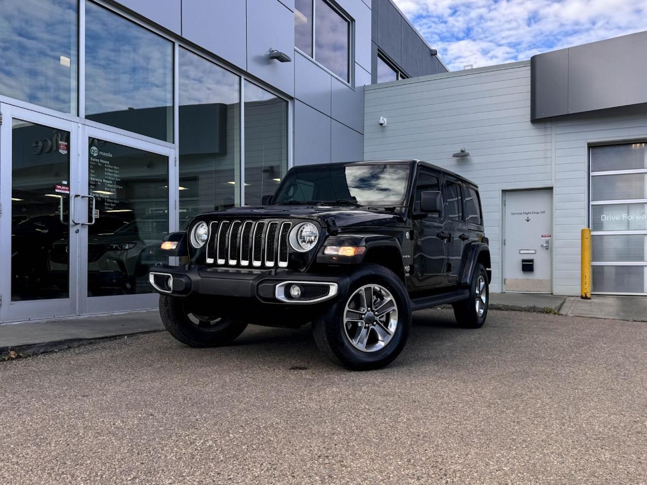 Climb inside of our 2022 Jeep Wrangler Unlimited Sahara in Black and feel at home! Its powered by a3.6 Liter Pentastar VVT V6 enginethat produces 285 horsepower while paired to a smooth shifting 8-Speed automatic transmission. The removeable hardtop, alloy wheels, and side steps heighten the off-road vibe of this 4WD 5 passenger SUV!Open the door to our Sahara and find a world of comfort and convenience, with premium, a leather-wrapped heated steering wheel with mounted audio/cruise controls, a6.5-inch touchscreen display, navigation, an AM/FM radio that is XM radio ready,automatic temperature control, and Bluetooth.Youll drive confidently knowing our Jeep has a wide variety of safety features including a backup camera, trailer sway control, a fleet of advanced airbags throughout the vehicle, anti-lock disc brakes, stability/traction control, and more!Print this page and call us Now... We Know You Will Enjoy Your Test Drive Towards Ownership! We look forward to showing you why Go Mazda is the best place for all your automotive needs.Go Mazda is an AMVIC licensed business.Please note: this vehicle was previously used as a Rental.