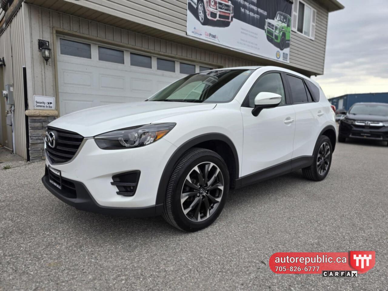 What sets this SUV apart is its outstanding reliability, thanks to its naturally aspirated engine and traditional 6-speed automatic transmission. Unlike many modern SUVs that rely on turbochargers or CVTs (continuously variable transmissions), this Mazda CX-5 offers a more dependable and responsive driving experience. <br/> <br/>  <br/> This 2016 Mazda CX-5 GT AWD offers the perfect balance of performance, luxury, and safety. Powered by a responsive 2.5L 4-cylinder engine and equipped with Mazdas advanced AWD system, this SUV is perfect for all seasons and road conditions. <br/> Key Features: <br/> Premium leather interior <br/> Power moonroof <br/> 19-inch alloy wheels <br/> Bose premium audio system <br/> Navigation system <br/> Heated front seats <br/> Blind-spot monitoring and rearview camera <br/> Keyless entry and push-button start <br/> Dual-zone climate control <br/> <br/>  <br/> The Mazda CX-5 is known for its sporty handling and excellent fuel economy, providing an enjoyable driving experience while saving at the pump. <br/> Well-Maintained & Ready to Drive <br/> This vehicle has been well cared for and regularly maintained by the single owner, making it a great option for those looking for reliability and style. <br/> <br/>  <br/> Comes Safety Certified <br/> <br/>  <br/> Link to Youtube walkaround video: <br/> https://www.youtube.com/watch?v=jamRGvXWnBc <br/> <br/>  <br/> Has only 105k kms, had one owner and never been in accidents - Carfax Verified <br/> Link to Carfax: <br/> https://vhr.carfax.ca/?id=za55pmTkvmgQwrengcblQXA974a1zk1p <br/> <br/>  <br/> Comes Safety Certified <br/> <br/>  <br/> Gorgeous color combination - shiny pearl white exterior on black mint leather interior. <br/> Smoke free, odor free interior. <br/> <br/>  <br/> Perfect combination of versatility, safety and reliability. <br/> <br/>  <br/> Please call 705-826-6777 for appointments <br/> www.autorepublic.ca <br/> <br/>  <br/> Available extended warranty up to 48 months <br/> <br/>  <br/> WE FINANCE EVERYONE. 100% APPROVAL (downpayment might be required) <br/> <br/>  <br/> Tax and Licensing extra <br/> <br/>  <br/> Trade-ins are welcome! <br/> <br/>  <br/> No Hidden Fees or Admin Fees! <br/> <br/>  <br/> Do not hesitate to contact us with any questions. <br/> <br/>  <br/> Please call us at 705/826/6777 for more details. <br/> www.autorepublic.ca <br/> <br/>  <br/> AUTO REPUBLIC <br/> Quality Certified Pre-Owned Vehicles <br/> 5 Courtland st, Ramara, ON. <br/>