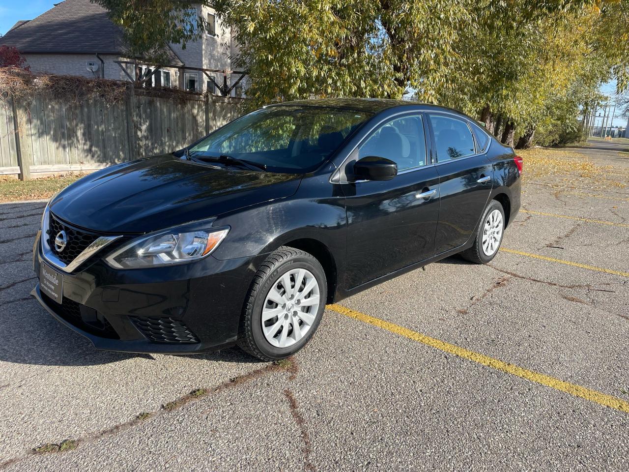 <p>Looking for a reliable and stylish sedan? Look no further than this 2019 Nissan Sentra SV, available now at Westside Sales! This sleek black beauty boasts a comfortable charcoal interior and a host of features designed to enhance your driving experience. With only 115,000km on the odometer, this Sentra is still in its prime, ready to take you on many more adventures.</p><p>This Sentra SV is packed with features that make every journey a pleasure. Enjoy the convenience of push-button start, heated seats, and power everything: windows, locks, mirrors, and even the trunk. Stay connected on the go with Bluetooth, while the rearview camera and a suite of safety features provide peace of mind behind the wheel.</p><p>Here are five features that truly make this Sentra stand out:</p><ul><li><strong>Push-Button Start:</strong> Say goodbye to fumbling with keys – simply press a button and go!</li><li><strong>Heated Seats:</strong> Stay warm and cozy on chilly mornings with heated front seats.</li><li><strong>Power Everything:</strong> Experience the ultimate convenience with power windows, locks, mirrors, and a power trunk for effortless access.</li><li><strong>Rearview Camera:</strong> Back up with confidence thanks to the added visibility of a rearview camera.</li><li><strong>Safety Suite:</strong> Drive with peace of mind knowing this Sentra is equipped with a comprehensive suite of safety features, including stability control, traction control, and multiple airbags.</li></ul><p>Come down to Westside Sales today and take this 2019 Nissan Sentra SV for a test drive. You wont be disappointed! <!-- [if gte mso 9]><xml><br />
 <o:OfficeDocumentSettings><br />
  <o:AllowPNG/><br />
 </o:OfficeDocumentSettings><br />
</xml><![endif]--><!-- [if gte mso 9]><xml><br />
 <w:WordDocument><br />
  <w:View>Normal</w:View><br />
  <w:Zoom>0</w:Zoom><br />
  <w:TrackMoves/><br />
  <w:TrackFormatting/><br />
  <w:PunctuationKerning/><br />
  <w:ValidateAgainstSchemas/><br />
  <w:SaveIfXMLInvalid>false</w:SaveIfXMLInvalid><br />
  <w:IgnoreMixedContent>false</w:IgnoreMixedContent><br />
  <w:AlwaysShowPlaceholderText>false</w:AlwaysShowPlaceholderText><br />
  <w:DoNotPromoteQF/><br />
  <w:LidThemeOther>EN-US</w:LidThemeOther><br />
  <w:LidThemeAsian>X-NONE</w:LidThemeAsian><br />
  <w:LidThemeComplexScript>X-NONE</w:LidThemeComplexScript><br />
  <w:Compatibility><br />
   <w:BreakWrappedTables/><br />
   <w:SnapToGridInCell/><br />
   <w:WrapTextWithPunct/><br />
   <w:UseAsianBreakRules/><br />
   <w:DontGrowAutofit/><br />
   <w:SplitPgBreakAndParaMark/><br />
   <w:EnableOpenTypeKerning/><br />
   <w:DontFlipMirrorIndents/><br />
   <w:OverrideTableStyleHps/><br />
  </w:Compatibility><br />
  <m:mathPr><br />
   <m:mathFont m:val=Cambria Math/><br />
   <m:brkBin m:val=before/><br />
   <m:brkBinSub m:val=--/><br />
   <m:smallFrac m:val=off/><br />
   <m:dispDef/><br />
   <m:lMargin m:val=0/><br />
   <m:rMargin m:val=0/><br />
   <m:defJc m:val=centerGroup/><br />
   <m:wrapIndent m:val=1440/><br />
   <m:intLim m:val=subSup/><br />
   <m:naryLim m:val=undOvr/><br />
  </m:mathPr></w:WordDocument><br />
</xml><![endif]--><!-- [if gte mso 9]><xml><br />
 <w:LatentStyles DefLockedState=false DefUnhideWhenUsed=false<br />
  DefSemiHidden=false DefQFormat=false DefPriority=99<br />
  LatentStyleCount=376><br />
  <w:LsdException Locked=false Priority=0 QFormat=true Name=Normal/><br />
  <w:LsdException Locked=false Priority=9 QFormat=true Name=heading 1/><br />
  <w:LsdException Locked=false Priority=9 SemiHidden=true<br />
   UnhideWhenUsed=true QFormat=true Name=heading 2/><br />
  <w:LsdException Locked=false Priority=9 SemiHidden=true<br />
   UnhideWhenUsed=true QFormat=true Name=heading 3/><br />
  <w:LsdException Locked=false Priority=9 SemiHidden=true<br />
   UnhideWhenUsed=true QFormat=true Name=heading 4/><br />
  <w:LsdException Locked=false Priority=9 SemiHidden=true<br />
   UnhideWhenUsed=true QFormat=true Name=heading 5/><br />
  <w:LsdException Locked=false Priority=9 SemiHidden=true<br />
   UnhideWhenUsed=true QFormat=true Name=heading 6/><br />
  <w:LsdException Locked=false Priority=9 SemiHidden=true<br />
   UnhideWhenUsed=true QFormat=true Name=heading 7/><br />
  <w:LsdException Locked=false Priority=9 SemiHidden=true<br />
   UnhideWhenUsed=true QFormat=true Name=heading 8/><br />
  <w:LsdException Locked=false Priority=9 SemiHidden=true<br />
   UnhideWhenUsed=true QFormat=true Name=heading 9/><br />
  <w:LsdException Locked=false SemiHidden=true UnhideWhenUsed=true<br />
   Name=index 1/><br />
  <w:LsdException Locked=false SemiHidden=true UnhideWhenUsed=true<br />
   Name=index 2/><br />
  <w:LsdException Locked=false SemiHidden=true UnhideWhenUsed=true<br />
   Name=index 3/><br />
  <w:LsdException Locked=false SemiHidden=true UnhideWhenUsed=true<br />
   Name=index 4/><br />
  <w:LsdException Locked=false SemiHidden=true UnhideWhenUsed=true<br />
   Name=index 5/><br />
  <w:LsdException Locked=false SemiHidden=true UnhideWhenUsed=true<br />
   Name=index 6/><br />
  <w:LsdException Locked=false SemiHidden=true UnhideWhenUsed=true<br />
   Name=index 7/><br />
  <w:LsdException Locked=false SemiHidden=true UnhideWhenUsed=true<br />
   Name=index 8/><br />
  <w:LsdException Locked=false SemiHidden=true UnhideWhenUsed=true<br />
   Name=index 9/><br />
  <w:LsdException Locked=false Priority=39 SemiHidden=true<br />
   UnhideWhenUsed=true Name=toc 1/><br />
  <w:LsdException Locked=false Priority=39 SemiHidden=true<br />
   UnhideWhenUsed=true Name=toc 2/><br />
  <w:LsdException Locked=false Priority=39 SemiHidden=true<br />
   UnhideWhenUsed=true Name=toc 3/><br />
  <w:LsdException Locked=false Priority=39 SemiHidden=true<br />
   UnhideWhenUsed=true Name=toc 4/><br />
  <w:LsdException Locked=false Priority=39 SemiHidden=true<br />
   UnhideWhenUsed=true Name=toc 5/><br />
  <w:LsdException Locked=false Priority=39 SemiHidden=true<br />
   UnhideWhenUsed=true Name=toc 6/><br />
  <w:LsdException Locked=false Priority=39 SemiHidden=true<br />
   UnhideWhenUsed=true Name=toc 7/><br />
  <w:LsdException Locked=false Priority=39 SemiHidden=true<br />
   UnhideWhenUsed=true Name=toc 8/><br />
  <w:LsdException Locked=false Priority=39 SemiHidden=true<br />
   UnhideWhenUsed=true Name=toc 9/><br />
  <w:LsdException Locked=false SemiHidden=true UnhideWhenUsed=true<br />
   Name=Normal Indent/><br />
  <w:LsdException Locked=false SemiHidden=true UnhideWhenUsed=true<br />
   Name=footnote text/><br />
  <w:LsdException Locked=false SemiHidden=true UnhideWhenUsed=true<br />
   Name=annotation text/><br />
  <w:LsdException Locked=false SemiHidden=true UnhideWhenUsed=true<br />
   Name=header/><br />
  <w:LsdException Locked=false SemiHidden=true UnhideWhenUsed=true<br />
   Name=footer/><br />
  <w:LsdException Locked=false SemiHidden=true UnhideWhenUsed=true<br />
   Name=index heading/><br />
  <w:LsdException Locked=false Priority=35 SemiHidden=true<br />
   UnhideWhenUsed=true QFormat=true Name=caption/><br />
  <w:LsdException Locked=false SemiHidden=true UnhideWhenUsed=true<br />
   Name=table of figures/><br />
  <w:LsdException Locked=false SemiHidden=true UnhideWhenUsed=true<br />
   Name=envelope address/><br />
  <w:LsdException Locked=false SemiHidden=true UnhideWhenUsed=true<br />
   Name=envelope return/><br />
  <w:LsdException Locked=false SemiHidden=true UnhideWhenUsed=true<br />
   Name=footnote reference/><br />
  <w:LsdException Locked=false SemiHidden=true UnhideWhenUsed=true<br />
   Name=annotation reference/><br />
  <w:LsdException Locked=false SemiHidden=true UnhideWhenUsed=true<br />
   Name=line number/><br />
  <w:LsdException Locked=false SemiHidden=true UnhideWhenUsed=true<br />
   Name=page number/><br />
  <w:LsdException Locked=false SemiHidden=true UnhideWhenUsed=true<br />
   Name=endnote reference/><br />
  <w:LsdException Locked=false SemiHidden=true UnhideWhenUsed=true<br />
   Name=endnote text/><br />
  <w:LsdException Locked=false SemiHidden=true UnhideWhenUsed=true<br />
   Name=table of authorities/><br />
  <w:LsdException Locked=false SemiHidden=true UnhideWhenUsed=true<br />
   Name=macro/><br />
  <w:LsdException Locked=false SemiHidden=true UnhideWhenUsed=true<br />
   Name=toa heading/><br />
  <w:LsdException Locked=false SemiHidden=true UnhideWhenUsed=true<br />
   Name=List/><br />
  <w:LsdException Locked=false SemiHidden=true UnhideWhenUsed=true<br />
   Name=List Bullet/><br />
  <w:LsdException Locked=false SemiHidden=true UnhideWhenUsed=true<br />
   Name=List Number/><br />
  <w:LsdException Locked=false SemiHidden=true UnhideWhenUsed=true<br />
   Name=List 2/><br />
  <w:LsdException Locked=false SemiHidden=true UnhideWhenUsed=true<br />
   Name=List 3/><br />
  <w:LsdException Locked=false SemiHidden=true UnhideWhenUsed=true<br />
   Name=List 4/><br />
  <w:LsdException Locked=false SemiHidden=true UnhideWhenUsed=true<br />
   Name=List 5/><br />
  <w:LsdException Locked=false SemiHidden=true UnhideWhenUsed=true<br />
   Name=List Bullet 2/><br />
  <w:LsdException Locked=false SemiHidden=true UnhideWhenUsed=true<br />
   Name=List Bullet 3/><br />
  <w:LsdException Locked=false SemiHidden=true UnhideWhenUsed=true<br />
   Name=List Bullet 4/><br />
  <w:LsdException Locked=false SemiHidden=true UnhideWhenUsed=true<br />
   Name=List Bullet 5/><br />
  <w:LsdException Locked=false SemiHidden=true UnhideWhenUsed=true<br />
   Name=List Number 2/><br />
  <w:LsdException Locked=false SemiHidden=true UnhideWhenUsed=true<br />
   Name=List Number 3/><br />
  <w:LsdException Locked=false SemiHidden=true UnhideWhenUsed=true<br />
   Name=List Number 4/><br />
  <w:LsdException Locked=false SemiHidden=true UnhideWhenUsed=true<br />
   Name=List Number 5/><br />
  <w:LsdException Locked=false Priority=10 QFormat=true Name=Title/><br />
  <w:LsdException Locked=false SemiHidden=true UnhideWhenUsed=true<br />
   Name=Closing/><br />
  <w:LsdException Locked=false SemiHidden=true UnhideWhenUsed=true<br />
   Name=Signature/><br />
  <w:LsdException Locked=false Priority=1 SemiHidden=true<br />
   UnhideWhenUsed=true Name=Default Paragraph Font/><br />
  <w:LsdException Locked=false SemiHidden=true UnhideWhenUsed=true<br />
   Name=Body Text/><br />
  <w:LsdException Locked=false SemiHidden=true UnhideWhenUsed=true<br />
   Name=Body Text Indent/><br />
  <w:LsdException Locked=false SemiHidden=true UnhideWhenUsed=true<br />
   Name=List Continue/><br />
  <w:LsdException Locked=false SemiHidden=true UnhideWhenUsed=true<br />
   Name=List Continue 2/><br />
  <w:LsdException Locked=false SemiHidden=true UnhideWhenUsed=true<br />
   Name=List Continue 3/><br />
  <w:LsdException Locked=false SemiHidden=true UnhideWhenUsed=true<br />
   Name=List Continue 4/><br />
  <w:LsdException Locked=false SemiHidden=true UnhideWhenUsed=true<br />
   Name=List Continue 5/><br />
  <w:LsdException Locked=false SemiHidden=true UnhideWhenUsed=true<br />
   Name=Message Header/><br />
  <w:LsdException Locked=false Priority=11 QFormat=true Name=Subtitle/><br />
  <w:LsdException Locked=false SemiHidden=true UnhideWhenUsed=true<br />
   Name=Salutation/><br />
  <w:LsdException Locked=false SemiHidden=true UnhideWhenUsed=true<br />
   Name=Date/><br />
  <w:LsdException Locked=false SemiHidden=true UnhideWhenUsed=true<br />
   Name=Body Text First Indent/><br />
  <w:LsdException Locked=false SemiHidden=true UnhideWhenUsed=true<br />
   Name=Body Text First Indent 2/><br />
  <w:LsdException Locked=false SemiHidden=true UnhideWhenUsed=true<br />
   Name=Note Heading/><br />
  <w:LsdException Locked=false SemiHidden=true UnhideWhenUsed=true<br />
   Name=Body Text 2/><br />
  <w:LsdException Locked=false SemiHidden=true UnhideWhenUsed=true<br />
   Name=Body Text 3/><br />
  <w:LsdException Locked=false SemiHidden=true UnhideWhenUsed=true<br />
   Name=Body Text Indent 2/><br />
  <w:LsdException Locked=false SemiHidden=true UnhideWhenUsed=true<br />
   Name=Body Text Indent 3/><br />
  <w:LsdException Locked=false SemiHidden=true UnhideWhenUsed=true<br />
   Name=Block Text/><br />
  <w:LsdException Locked=false SemiHidden=true UnhideWhenUsed=true<br />
   Name=Hyperlink/><br />
  <w:LsdException Locked=false SemiHidden=true UnhideWhenUsed=true<br />
   Name=FollowedHyperlink/><br />
  <w:LsdException Locked=false Priority=22 QFormat=true Name=Strong/><br />
  <w:LsdException Locked=false Priority=20 QFormat=true Name=Emphasis/><br />
  <w:LsdException Locked=false SemiHidden=true UnhideWhenUsed=true<br />
   Name=Document Map/><br />
  <w:LsdException Locked=false SemiHidden=true UnhideWhenUsed=true<br />
   Name=Plain Text/><br />
  <w:LsdException Locked=false SemiHidden=true UnhideWhenUsed=true<br />
   Name=E-mail Signature/><br />
  <w:LsdException Locked=false SemiHidden=true UnhideWhenUsed=true<br />
   Name=HTML Top of Form/><br />
  <w:LsdException Locked=false SemiHidden=true UnhideWhenUsed=true<br />
   Name=HTML Bottom of Form/><br />
  <w:LsdException Locked=false SemiHidden=true UnhideWhenUsed=true<br />
   Name=Normal (Web)/><br />
  <w:LsdException Locked=false SemiHidden=true UnhideWhenUsed=true<br />
   Name=HTML Acronym/><br />
  <w:LsdException Locked=false SemiHidden=true UnhideWhenUsed=true<br />
   Name=HTML Address/><br />
  <w:LsdException Locked=false SemiHidden=true UnhideWhenUsed=true<br />
   Name=HTML Cite/><br />
  <w:LsdException Locked=false SemiHidden=true UnhideWhenUsed=true<br />
   Name=HTML Code/><br />
  <w:LsdException Locked=false SemiHidden=true UnhideWhenUsed=true<br />
   Name=HTML Definition/><br />
  <w:LsdException Locked=false SemiHidden=true UnhideWhenUsed=true<br />
   Name=HTML Keyboard/><br />
  <w:LsdException Locked=false SemiHidden=true UnhideWhenUsed=true<br />
   Name=HTML Preformatted/><br />
  <w:LsdException Locked=false SemiHidden=true UnhideWhenUsed=true<br />
   Name=HTML Sample/><br />
  <w:LsdException Locked=false SemiHidden=true UnhideWhenUsed=true<br />
   Name=HTML Typewriter/><br />
  <w:LsdException Locked=false SemiHidden=true UnhideWhenUsed=true<br />
   Name=HTML Variable/><br />
  <w:LsdException Locked=false SemiHidden=true UnhideWhenUsed=true<br />
   Name=Normal Table/><br />
  <w:LsdException Locked=false SemiHidden=true UnhideWhenUsed=true<br />
   Name=annotation subject/><br />
  <w:LsdException Locked=false SemiHidden=true UnhideWhenUsed=true<br />
   Name=No List/><br />
  <w:LsdException Locked=false SemiHidden=true UnhideWhenUsed=true<br />
   Name=Outline List 1/><br />
  <w:LsdException Locked=false SemiHidden=true UnhideWhenUsed=true<br />
   Name=Outline List 2/><br />
  <w:LsdException Locked=false SemiHidden=true UnhideWhenUsed=true<br />
   Name=Outline List 3/><br />
  <w:LsdException Locked=false SemiHidden=true UnhideWhenUsed=true<br />
   Name=Table Simple 1/><br />
  <w:LsdException Locked=false SemiHidden=true UnhideWhenUsed=true<br />
   Name=Table Simple 2/><br />
  <w:LsdException Locked=false SemiHidden=true UnhideWhenUsed=true<br />
   Name=Table Simple 3/><br />
  <w:LsdException Locked=false SemiHidden=true UnhideWhenUsed=true<br />
   Name=Table Classic 1/><br />
  <w:LsdException Locked=false SemiHidden=true UnhideWhenUsed=true<br />
   Name=Table Classic 2/><br />
  <w:LsdException Locked=false SemiHidden=true UnhideWhenUsed=true<br />
   Name=Table Classic 3/><br />
  <w:LsdException Locked=false SemiHidden=true UnhideWhenUsed=true<br />
   Name=Table Classic 4/><br />
  <w:LsdException Locked=false SemiHidden=true UnhideWhenUsed=true<br />
   Name=Table Colorful 1/><br />
  <w:LsdException Locked=false SemiHidden=true UnhideWhenUsed=true<br />
   Name=Table Colorful 2/><br />
  <w:LsdException Locked=false SemiHidden=true UnhideWhenUsed=true<br />
   Name=Table Colorful 3/><br />
  <w:LsdException Locked=false SemiHidden=true UnhideWhenUsed=true<br />
   Name=Table Columns 1/><br />
  <w:LsdException Locked=false SemiHidden=true UnhideWhenUsed=true<br />
   Name=Table Columns 2/><br />
  <w:LsdException Locked=false SemiHidden=true UnhideWhenUsed=true<br />
   Name=Table Columns 3/><br />
  <w:LsdException Locked=false SemiHidden=true UnhideWhenUsed=true<br />
   Name=Table Columns 4/><br />
  <w:LsdException Locked=false SemiHidden=true UnhideWhenUsed=true<br />
   Name=Table Columns 5/><br />
  <w:LsdException Locked=false SemiHidden=true UnhideWhenUsed=true<br />
   Name=Table Grid 1/><br />
  <w:LsdException Locked=false SemiHidden=true UnhideWhenUsed=true<br />
   Name=Table Grid 2/><br />
  <w:LsdException Locked=false SemiHidden=true UnhideWhenUsed=true<br />
   Name=Table Grid 3/><br />
  <w:LsdException Locked=false SemiHidden=true UnhideWhenUsed=true<br />
   Name=Table Grid 4/><br />
  <w:LsdException Locked=false SemiHidden=true UnhideWhenUsed=true<br />
   Name=Table Grid 5/><br />
  <w:LsdException Locked=false SemiHidden=true UnhideWhenUsed=true<br />
   Name=Table Grid 6/><br />
  <w:LsdException Locked=false SemiHidden=true UnhideWhenUsed=true<br />
   Name=Table Grid 7/><br />
  <w:LsdException Locked=false SemiHidden=true UnhideWhenUsed=true<br />
   Name=Table Grid 8/><br />
  <w:LsdException Locked=false SemiHidden=true UnhideWhenUsed=true<br />
   Name=Table List 1/><br />
  <w:LsdException Locked=false SemiHidden=true UnhideWhenUsed=true<br />
   Name=Table List 2/><br />
  <w:LsdException Locked=false SemiHidden=true UnhideWhenUsed=true<br />
   Name=Table List 3/><br />
  <w:LsdException Locked=false SemiHidden=true UnhideWhenUsed=true<br />
   Name=Table List 4/><br />
  <w:LsdException Locked=false SemiHidden=true UnhideWhenUsed=true<br />
   Name=Table List 5/><br />
  <w:LsdException Locked=false SemiHidden=true UnhideWhenUsed=true<br />
   Name=Table List 6/><br />
  <w:LsdException Locked=false SemiHidden=true UnhideWhenUsed=true<br />
   Name=Table List 7/><br />
  <w:LsdException Locked=false SemiHidden=true UnhideWhenUsed=true<br />
   Name=Table List 8/><br />
  <w:LsdException Locked=false SemiHidden=true UnhideWhenUsed=true<br />
   Name=Table 3D effects 1/><br />
  <w:LsdException Locked=false SemiHidden=true UnhideWhenUsed=true<br />
   Name=Table 3D effects 2/><br />
  <w:LsdException Locked=false SemiHidden=true UnhideWhenUsed=true<br />
   Name=Table 3D effects 3/><br />
  <w:LsdException Locked=false SemiHidden=true UnhideWhenUsed=true<br />
   Name=Table Contemporary/><br />
  <w:LsdException Locked=false SemiHidden=true UnhideWhenUsed=true<br />
   Name=Table Elegant/><br />
  <w:LsdException Locked=false SemiHidden=true UnhideWhenUsed=true<br />
   Name=Table Professional/><br />
  <w:LsdException Locked=false SemiHidden=true UnhideWhenUsed=true<br />
   Name=Table Subtle 1/><br />
  <w:LsdException Locked=false SemiHidden=true UnhideWhenUsed=true<br />
   Name=Table Subtle 2/><br />
  <w:LsdException Locked=false SemiHidden=true UnhideWhenUsed=true<br />
   Name=Table Web 1/><br />
  <w:LsdException Locked=false SemiHidden=true UnhideWhenUsed=true<br />
   Name=Table Web 2/><br />
  <w:LsdException Locked=false SemiHidden=true UnhideWhenUsed=true<br />
   Name=Table Web 3/><br />
  <w:LsdException Locked=false SemiHidden=true UnhideWhenUsed=true<br />
   Name=Balloon Text/><br />
  <w:LsdException Locked=false Priority=39 Name=Table Grid/><br />
  <w:LsdException Locked=false SemiHidden=true UnhideWhenUsed=true<br />
   Name=Table Theme/><br />
  <w:LsdException Locked=false SemiHidden=true Name=Placeholder Text/><br />
  <w:LsdException Locked=false Priority=1 QFormat=true Name=No Spacing/><br />
  <w:LsdException Locked=false Priority=60 Name=Light Shading/><br />
  <w:LsdException Locked=false Priority=61 Name=Light List/><br />
  <w:LsdException Locked=false Priority=62 Name=Light Grid/><br />
  <w:LsdException Locked=false Priority=63 Name=Medium Shading 1/><br />
  <w:LsdException Locked=false Priority=64 Name=Medium Shading 2/><br />
  <w:LsdException Locked=false Priority=65 Name=Medium List 1/><br />
  <w:LsdException Locked=false Priority=66 Name=Medium List 2/><br />
  <w:LsdException Locked=false Priority=67 Name=Medium Grid 1/><br />
  <w:LsdException Locked=false Priority=68 Name=Medium Grid 2/><br />
  <w:LsdException Locked=false Priority=69 Name=Medium Grid 3/><br />
  <w:LsdException Locked=false Priority=70 Name=Dark List/><br />
  <w:LsdException Locked=false Priority=71 Name=Colorful Shading/><br />
  <w:LsdException Locked=false Priority=72 Name=Colorful List/><br />
  <w:LsdException Locked=false Priority=73 Name=Colorful Grid/><br />
  <w:LsdException Locked=false Priority=60 Name=Light Shading Accent 1/><br />
  <w:LsdException Locked=false Priority=61 Name=Light List Accent 1/><br />
  <w:LsdException Locked=false Priority=62 Name=Light Grid Accent 1/><br />
  <w:LsdException Locked=false Priority=63 Name=Medium Shading 1 Accent 1/><br />
  <w:LsdException Locked=false Priority=64 Name=Medium Shading 2 Accent 1/><br />
  <w:LsdException Locked=false Priority=65 Name=Medium List 1 Accent 1/><br />
  <w:LsdException Locked=false SemiHidden=true Name=Revision/><br />
  <w:LsdException Locked=false Priority=34 QFormat=true<br />
   Name=List Paragraph/><br />
  <w:LsdException Locked=false Priority=29 QFormat=true Name=Quote/><br />
  <w:LsdException Locked=false Priority=30 QFormat=true<br />
   Name=Intense Quote/><br />
  <w:LsdException Locked=false Priority=66 Name=Medium List 2 Accent 1/><br />
  <w:LsdException Locked=false Priority=67 Name=Medium Grid 1 Accent 1/><br />
  <w:LsdException Locked=false Priority=68 Name=Medium Grid 2 Accent 1/><br />
  <w:LsdException Locked=false Priority=69 Name=Medium Grid 3 Accent 1/><br />
  <w:LsdException Locked=false Priority=70 Name=Dark List Accent 1/><br />
  <w:LsdException Locked=false Priority=71 Name=Colorful Shading Accent 1/><br />
  <w:LsdException Locked=false Priority=72 Name=Colorful List Accent 1/><br />
  <w:LsdException Locked=false Priority=73 Name=Colorful Grid Accent 1/><br />
  <w:LsdException Locked=false Priority=60 Name=Light Shading Accent 2/><br />
  <w:LsdException Locked=false Priority=61 Name=Light List Accent 2/><br />
  <w:LsdException Locked=false Priority=62 Name=Light Grid Accent 2/><br />
  <w:LsdException Locked=false Priority=63 Name=Medium Shading 1 Accent 2/><br />
  <w:LsdException Locked=false Priority=64 Name=Medium Shading 2 Accent 2/><br />
  <w:LsdException Locked=false Priority=65 Name=Medium List 1 Accent 2/><br />
  <w:LsdException Locked=false Priority=66 Name=Medium List 2 Accent 2/><br />
  <w:LsdException Locked=false Priority=67 Name=Medium Grid 1 Accent 2/><br />
  <w:LsdException Locked=false Priority=68 Name=Medium Grid 2 Accent 2/><br />
  <w:LsdException Locked=false Priority=69 Name=Medium Grid 3 Accent 2/><br />
  <w:LsdException Locked=false Priority=70 Name=Dark List Accent 2/><br />
  <w:LsdException Locked=false Priority=71 Name=Colorful Shading Accent 2/><br />
  <w:LsdException Locked=false Priority=72 Name=Colorful List Accent 2/><br />
  <w:LsdException Locked=false Priority=73 Name=Colorful Grid Accent 2/><br />
  <w:LsdException Locked=false Priority=60 Name=Light Shading Accent 3/><br />
  <w:LsdException Locked=false Priority=61 Name=Light List Accent 3/><br />
  <w:LsdException Locked=false Priority=62 Name=Light Grid Accent 3/><br />
  <w:LsdException Locked=false Priority=63 Name=Medium Shading 1 Accent 3/><br />
  <w:LsdException Locked=false Priority=64 Name=Medium Shading 2 Accent 3/><br />
  <w:LsdException Locked=false Priority=65 Name=Medium List 1 Accent 3/><br />
  <w:LsdException Locked=false Priority=66 Name=Medium List 2 Accent 3/><br />
  <w:LsdException Locked=false Priority=67 Name=Medium Grid 1 Accent 3/><br />
  <w:LsdException Locked=false Priority=68 Name=Medium Grid 2 Accent 3/><br />
  <w:LsdException Locked=false Priority=69 Name=Medium Grid 3 Accent 3/><br />
  <w:LsdException Locked=false Priority=70 Name=Dark List Accent 3/><br />
  <w:LsdException Locked=false Priority=71 Name=Colorful Shading Accent 3/><br />
  <w:LsdException Locked=false Priority=72 Name=Colorful List Accent 3/><br />
  <w:LsdException Locked=false Priority=73 Name=Colorful Grid Accent 3/><br />
  <w:LsdException Locked=false Priority=60 Name=Light Shading Accent 4/><br />
  <w:LsdException Locked=false Priority=61 Name=Light List Accent 4/><br />
  <w:LsdException Locked=false Priority=62 Name=Light Grid Accent 4/><br />
  <w:LsdException Locked=false Priority=63 Name=Medium Shading 1 Accent 4/><br />
  <w:LsdException Locked=false Priority=64 Name=Medium Shading 2 Accent 4/><br />
  <w:LsdException Locked=false Priority=65 Name=Medium List 1 Accent 4/><br />
  <w:LsdException Locked=false Priority=66 Name=Medium List 2 Accent 4/><br />
  <w:LsdException Locked=false Priority=67 Name=Medium Grid 1 Accent 4/><br />
  <w:LsdException Locked=false Priority=68 Name=Medium Grid 2 Accent 4/><br />
  <w:LsdException Locked=false Priority=69 Name=Medium Grid 3 Accent 4/><br />
  <w:LsdException Locked=false Priority=70 Name=Dark List Accent 4/><br />
  <w:LsdException Locked=false Priority=71 Name=Colorful Shading Accent 4/><br />
  <w:LsdException Locked=false Priority=72 Name=Colorful List Accent 4/><br />
  <w:LsdException Locked=false Priority=73 Name=Colorful Grid Accent 4/><br />
  <w:LsdException Locked=false Priority=60 Name=Light Shading Accent 5/><br />
  <w:LsdException Locked=false Priority=61 Name=Light List Accent 5/><br />
  <w:LsdException Locked=false Priority=62 Name=Light Grid Accent 5/><br />
  <w:LsdException Locked=false Priority=63 Name=Medium Shading 1 Accent 5/><br />
  <w:LsdException Locked=false Priority=64 Name=Medium Shading 2 Accent 5/><br />
  <w:LsdException Locked=false Priority=65 Name=Medium List 1 Accent 5/><br />
  <w:LsdException Locked=false Priority=66 Name=Medium List 2 Accent 5/><br />
  <w:LsdException Locked=false Priority=67 Name=Medium Grid 1 Accent 5/><br />
  <w:LsdException Locked=false Priority=68 Name=Medium Grid 2 Accent 5/><br />
  <w:LsdException Locked=false Priority=69 Name=Medium Grid 3 Accent 5/><br />
  <w:LsdException Locked=false Priority=70 Name=Dark List Accent 5/><br />
  <w:LsdException Locked=false Priority=71 Name=Colorful Shading Accent 5/><br />
  <w:LsdException Locked=false Priority=72 Name=Colorful List Accent 5/><br />
  <w:LsdException Locked=false Priority=73 Name=Colorful Grid Accent 5/><br />
  <w:LsdException Locked=false Priority=60 Name=Light Shading Accent 6/><br />
  <w:LsdException Locked=false Priority=61 Name=Light List Accent 6/><br />
  <w:LsdException Locked=false Priority=62 Name=Light Grid Accent 6/><br />
  <w:LsdException Locked=false Priority=63 Name=Medium Shading 1 Accent 6/><br />
  <w:LsdException Locked=false Priority=64 Name=Medium Shading 2 Accent 6/><br />
  <w:LsdException Locked=false Priority=65 Name=Medium List 1 Accent 6/><br />
  <w:LsdException Locked=false Priority=66 Name=Medium List 2 Accent 6/><br />
  <w:LsdException Locked=false Priority=67 Name=Medium Grid 1 Accent 6/><br />
  <w:LsdException Locked=false Priority=68 Name=Medium Grid 2 Accent 6/><br />
  <w:LsdException Locked=false Priority=69 Name=Medium Grid 3 Accent 6/><br />
  <w:LsdException Locked=false Priority=70 Name=Dark List Accent 6/><br />
  <w:LsdException Locked=false Priority=71 Name=Colorful Shading Accent 6/><br />
  <w:LsdException Locked=false Priority=72 Name=Colorful List Accent 6/><br />
  <w:LsdException Locked=false Priority=73 Name=Colorful Grid Accent 6/><br />
  <w:LsdException Locked=false Priority=19 QFormat=true<br />
   Name=Subtle Emphasis/><br />
  <w:LsdException Locked=false Priority=21 QFormat=true<br />
   Name=Intense Emphasis/><br />
  <w:LsdException Locked=false Priority=31 QFormat=true<br />
   Name=Subtle Reference/><br />
  <w:LsdException Locked=false Priority=32 QFormat=true<br />
   Name=Intense Reference/><br />
  <w:LsdException Locked=false Priority=33 QFormat=true Name=Book Title/><br />
  <w:LsdException Locked=false Priority=37 SemiHidden=true<br />
   UnhideWhenUsed=true Name=Bibliography/><br />
  <w:LsdException Locked=false Priority=39 SemiHidden=true<br />
   UnhideWhenUsed=true QFormat=true Name=TOC Heading/><br />
  <w:LsdException Locked=false Priority=41 Name=Plain Table 1/><br />
  <w:LsdException Locked=false Priority=42 Name=Plain Table 2/><br />
  <w:LsdException Locked=false Priority=43 Name=Plain Table 3/><br />
  <w:LsdException Locked=false Priority=44 Name=Plain Table 4/><br />
  <w:LsdException Locked=false Priority=45 Name=Plain Table 5/><br />
  <w:LsdException Locked=false Priority=40 Name=Grid Table Light/><br />
  <w:LsdException Locked=false Priority=46 Name=Grid Table 1 Light/><br />
  <w:LsdException Locked=false Priority=47 Name=Grid Table 2/><br />
  <w:LsdException Locked=false Priority=48 Name=Grid Table 3/><br />
  <w:LsdException Locked=false Priority=49 Name=Grid Table 4/><br />
  <w:LsdException Locked=false Priority=50 Name=Grid Table 5 Dark/><br />
  <w:LsdException Locked=false Priority=51 Name=Grid Table 6 Colorful/><br />
  <w:LsdException Locked=false Priority=52 Name=Grid Table 7 Colorful/><br />
  <w:LsdException Locked=false Priority=46<br />
   Name=Grid Table 1 Light Accent 1/><br />
  <w:LsdException Locked=false Priority=47 Name=Grid Table 2 Accent 1/><br />
  <w:LsdException Locked=false Priority=48 Name=Grid Table 3 Accent 1/><br />
  <w:LsdException Locked=false Priority=49 Name=Grid Table 4 Accent 1/><br />
  <w:LsdException Locked=false Priority=50 Name=Grid Table 5 Dark Accent 1/><br />
  <w:LsdException Locked=false Priority=51<br />
   Name=Grid Table 6 Colorful Accent 1/><br />
  <w:LsdException Locked=false Priority=52<br />
   Name=Grid Table 7 Colorful Accent 1/><br />
  <w:LsdException Locked=false Priority=46<br />
   Name=Grid Table 1 Light Accent 2/><br />
  <w:LsdException Locked=false Priority=47 Name=Grid Table 2 Accent 2/><br />
  <w:LsdException Locked=false Priority=48 Name=Grid Table 3 Accent 2/><br />
  <w:LsdException Locked=false Priority=49 Name=Grid Table 4 Accent 2/><br />
  <w:LsdException Locked=false Priority=50 Name=Grid Table 5 Dark Accent 2/><br />
  <w:LsdException Locked=false Priority=51<br />
   Name=Grid Table 6 Colorful Accent 2/><br />
  <w:LsdException Locked=false Priority=52<br />
   Name=Grid Table 7 Colorful Accent 2/><br />
  <w:LsdException Locked=false Priority=46<br />
   Name=Grid Table 1 Light Accent 3/><br />
  <w:LsdException Locked=false Priority=47 Name=Grid Table 2 Accent 3/><br />
  <w:LsdException Locked=false Priority=48 Name=Grid Table 3 Accent 3/><br />
  <w:LsdException Locked=false Priority=49 Name=Grid Table 4 Accent 3/><br />
  <w:LsdException Locked=false Priority=50 Name=Grid Table 5 Dark Accent 3/><br />
  <w:LsdException Locked=false Priority=51<br />
   Name=Grid Table 6 Colorful Accent 3/><br />
  <w:LsdException Locked=false Priority=52<br />
   Name=Grid Table 7 Colorful Accent 3/><br />
  <w:LsdException Locked=false Priority=46<br />
   Name=Grid Table 1 Light Accent 4/><br />
  <w:LsdException Locked=false Priority=47 Name=Grid Table 2 Accent 4/><br />
  <w:LsdException Locked=false Priority=48 Name=Grid Table 3 Accent 4/><br />
  <w:LsdException Locked=false Priority=49 Name=Grid Table 4 Accent 4/><br />
  <w:LsdException Locked=false Priority=50 Name=Grid Table 5 Dark Accent 4/><br />
  <w:LsdException Locked=false Priority=51<br />
   Name=Grid Table 6 Colorful Accent 4/><br />
  <w:LsdException Locked=false Priority=52<br />
   Name=Grid Table 7 Colorful Accent 4/><br />
  <w:LsdException Locked=false Priority=46<br />
   Name=Grid Table 1 Light Accent 5/><br />
  <w:LsdException Locked=false Priority=47 Name=Grid Table 2 Accent 5/><br />
  <w:LsdException Locked=false Priority=48 Name=Grid Table 3 Accent 5/><br />
  <w:LsdException Locked=false Priority=49 Name=Grid Table 4 Accent 5/><br />
  <w:LsdException Locked=false Priority=50 Name=Grid Table 5 Dark Accent 5/><br />
  <w:LsdException Locked=false Priority=51<br />
   Name=Grid Table 6 Colorful Accent 5/><br />
  <w:LsdException Locked=false Priority=52<br />
   Name=Grid Table 7 Colorful Accent 5/><br />
  <w:LsdException Locked=false Priority=46<br />
   Name=Grid Table 1 Light Accent 6/><br />
  <w:LsdException Locked=false Priority=47 Name=Grid Table 2 Accent 6/><br />
  <w:LsdException Locked=false Priority=48 Name=Grid Table 3 Accent 6/><br />
  <w:LsdException Locked=false Priority=49 Name=Grid Table 4 Accent 6/><br />
  <w:LsdException Locked=false Priority=50 Name=Grid Table 5 Dark Accent 6/><br />
  <w:LsdException Locked=false Priority=51<br />
   Name=Grid Table 6 Colorful Accent 6/><br />
  <w:LsdException Locked=false Priority=52<br />
   Name=Grid Table 7 Colorful Accent 6/><br />
  <w:LsdException Locked=false Priority=46 Name=List Table 1 Light/><br />
  <w:LsdException Locked=false Priority=47 Name=List Table 2/><br />
  <w:LsdException Locked=false Priority=48 Name=List Table 3/><br />
  <w:LsdException Locked=false Priority=49 Name=List Table 4/><br />
  <w:LsdException Locked=false Priority=50 Name=List Table 5 Dark/><br />
  <w:LsdException Locked=false Priority=51 Name=List Table 6 Colorful/><br />
  <w:LsdException Locked=false Priority=52 Name=List Table 7 Colorful/><br />
  <w:LsdException Locked=false Priority=46<br />
   Name=List Table 1 Light Accent 1/><br />
  <w:LsdException Locked=false Priority=47 Name=List Table 2 Accent 1/><br />
  <w:LsdException Locked=false Priority=48 Name=List Table 3 Accent 1/><br />
  <w:LsdException Locked=false Priority=49 Name=List Table 4 Accent 1/><br />
  <w:LsdException Locked=false Priority=50 Name=List Table 5 Dark Accent 1/><br />
  <w:LsdException Locked=false Priority=51<br />
   Name=List Table 6 Colorful Accent 1/><br />
  <w:LsdException Locked=false Priority=52<br />
   Name=List Table 7 Colorful Accent 1/><br />
  <w:LsdException Locked=false Priority=46<br />
   Name=List Table 1 Light Accent 2/><br />
  <w:LsdException Locked=false Priority=47 Name=List Table 2 Accent 2/><br />
  <w:LsdException Locked=false Priority=48 Name=List Table 3 Accent 2/><br />
  <w:LsdException Locked=false Priority=49 Name=List Table 4 Accent 2/><br />
  <w:LsdException Locked=false Priority=50 Name=List Table 5 Dark Accent 2/><br />
  <w:LsdException Locked=false Priority=51<br />
   Name=List Table 6 Colorful Accent 2/><br />
  <w:LsdException Locked=false Priority=52<br />
   Name=List Table 7 Colorful Accent 2/><br />
  <w:LsdException Locked=false Priority=46<br />
   Name=List Table 1 Light Accent 3/><br />
  <w:LsdException Locked=false Priority=47 Name=List Table 2 Accent 3/><br />
  <w:LsdException Locked=false Priority=48 Name=List Table 3 Accent 3/><br />
  <w:LsdException Locked=false Priority=49 Name=List Table 4 Accent 3/><br />
  <w:LsdException Locked=false Priority=50 Name=List Table 5 Dark Accent 3/><br />
  <w:LsdException Locked=false Priority=51<br />
   Name=List Table 6 Colorful Accent 3/><br />
  <w:LsdException Locked=false Priority=52<br />
   Name=List Table 7 Colorful Accent 3/><br />
  <w:LsdException Locked=false Priority=46<br />
   Name=List Table 1 Light Accent 4/><br />
  <w:LsdException Locked=false Priority=47 Name=List Table 2 Accent 4/><br />
  <w:LsdException Locked=false Priority=48 Name=List Table 3 Accent 4/><br />
  <w:LsdException Locked=false Priority=49 Name=List Table 4 Accent 4/><br />
  <w:LsdException Locked=false Priority=50 Name=List Table 5 Dark Accent 4/><br />
  <w:LsdException Locked=false Priority=51<br />
   Name=List Table 6 Colorful Accent 4/><br />
  <w:LsdException Locked=false Priority=52<br />
   Name=List Table 7 Colorful Accent 4/><br />
  <w:LsdException Locked=false Priority=46<br />
   Name=List Table 1 Light Accent 5/><br />
  <w:LsdException Locked=false Priority=47 Name=List Table 2 Accent 5/><br />
  <w:LsdException Locked=false Priority=48 Name=List Table 3 Accent 5/><br />
  <w:LsdException Locked=false Priority=49 Name=List Table 4 Accent 5/><br />
  <w:LsdException Locked=false Priority=50 Name=List Table 5 Dark Accent 5/><br />
  <w:LsdException Locked=false Priority=51<br />
   Name=List Table 6 Colorful Accent 5/><br />
  <w:LsdException Locked=false Priority=52<br />
   Name=List Table 7 Colorful Accent 5/><br />
  <w:LsdException Locked=false Priority=46<br />
   Name=List Table 1 Light Accent 6/><br />
  <w:LsdException Locked=false Priority=47 Name=List Table 2 Accent 6/><br />
  <w:LsdException Locked=false Priority=48 Name=List Table 3 Accent 6/><br />
  <w:LsdException Locked=false Priority=49 Name=List Table 4 Accent 6/><br />
  <w:LsdException Locked=false Priority=50 Name=List Table 5 Dark Accent 6/><br />
  <w:LsdException Locked=false Priority=51<br />
   Name=List Table 6 Colorful Accent 6/><br />
  <w:LsdException Locked=false Priority=52<br />
   Name=List Table 7 Colorful Accent 6/><br />
  <w:LsdException Locked=false SemiHidden=true UnhideWhenUsed=true<br />
   Name=Mention/><br />
  <w:LsdException Locked=false SemiHidden=true UnhideWhenUsed=true<br />
   Name=Smart Hyperlink/><br />
  <w:LsdException Locked=false SemiHidden=true UnhideWhenUsed=true<br />
   Name=Hashtag/><br />
  <w:LsdException Locked=false SemiHidden=true UnhideWhenUsed=true<br />
   Name=Unresolved Mention/><br />
  <w:LsdException Locked=false SemiHidden=true UnhideWhenUsed=true<br />
   Name=Smart Link/><br />
 </w:LatentStyles><br />
</xml><![endif]--><!-- [if gte mso 10]><br />
<style><br />
 /* Style Definitions */<br />
 table.MsoNormalTable<br />
	{mso-style-name:Table Normal;<br />
	mso-tstyle-rowband-size:0;<br />
	mso-tstyle-colband-size:0;<br />
	mso-style-noshow:yes;<br />
	mso-style-priority:99;<br />
	mso-style-parent:;<br />
	mso-padding-alt:0in 5.4pt 0in 5.4pt;<br />
	mso-para-margin-top:0in;<br />
	mso-para-margin-right:0in;<br />
	mso-para-margin-bottom:8.0pt;<br />
	mso-para-margin-left:0in;<br />
	line-height:107%;<br />
	mso-pagination:widow-orphan;<br />
	font-size:11.0pt;<br />
	font-family:Calibri,sans-serif;<br />
	mso-ascii-font-family:Calibri;<br />
	mso-ascii-theme-font:minor-latin;<br />
	mso-hansi-font-family:Calibri;<br />
	mso-hansi-theme-font:minor-latin;<br />
	mso-bidi-font-family:Times New Roman;<br />
	mso-bidi-theme-font:minor-bidi;<br />
	mso-font-kerning:1.0pt;<br />
	mso-ligatures:standardcontextual;}<br />
</style><br />
<![endif]--></p><p>1461 Waverley Street 204 488 3793. All vehicles safety certified and serviced, licensed technician on staff . Buy with confidence, We are one of the most established used car dealerships in Winnipeg. Come check us out... theres a reason we have been around since 1985 at the same location.<span style=mso-spacerun: yes;>    </span>See our other great deals at WWW.Westsidesales.CA Apply for financing on our website.<span style=mso-spacerun: yes;>  </span>Check us out on facebook and instagram @westsidesale<span style=mso-spacerun: yes;>   </span>DP#9491</p><p><em>Powered by AutoIntelligence™ AI</em></p>