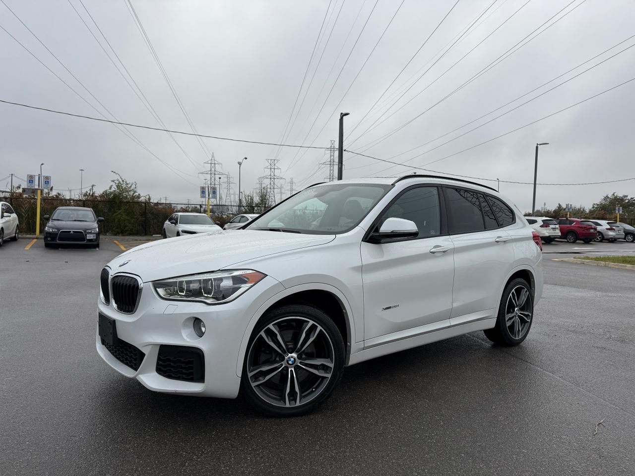 <p>Get ready to elevate your driving experience with this sleek and stylish 2017 BMW X1, available now at Select Auto Centre Ltd.! This pre-owned SUV boasts a captivating white exterior with a luxurious black interior, making a statement wherever you go. The M Package adds an aggressive touch with performance-inspired styling, while the panoramic sunroof provides breathtaking views of the sky. With its 4-cylinder engine and all-wheel drive, this X1 delivers a thrilling ride that seamlessly blends power and efficiency.</p><p>This X1 comes loaded with an array of features designed to enhance your comfort and safety. The heated seats and heated steering wheel will keep you cozy on chilly mornings, while the Heads Up Display projects crucial information onto the windshield for easy access. Stay connected on the road with Bluetooth connectivity and enjoy the premium sound system. With keyless entry and push-button start, youll experience the ultimate convenience. This vehicle has been well-maintained and only has 110,550km on the odometer, ensuring years of reliable performance. </p><p>$18888 + HST & LIC.</p><p><strong>Here are 5 features that will make you want to take this X1 for a spin:</strong></p><ul><li><strong>M Package:</strong> This performance-inspired package adds a sporty edge to the X1s design, enhancing its visual appeal and driving experience.</li><li><strong>Panoramic Sunroof:</strong> Let the sunshine in and enjoy expansive views with this panoramic sunroof.</li><li><strong>Heads Up Display:</strong> Keep your eyes on the road and stay informed with crucial information projected directly onto the windshield.</li><li><strong>Heated Seats & Steering Wheel:</strong> Stay warm and comfortable on even the coldest days with these luxurious features.</li><li><strong>Premium Sound System:</strong> Immerse yourself in your favorite music with this high-quality sound system.</li></ul><p style=box-sizing: border-box; padding: 0px; margin: 0px 0px 1.375rem;><span style=box-sizing: border-box;>**Select Auto has financing options for good credit, no credit or poor credit. No Credit = NO PROBLEM!! Drop by our Etobicoke Dealership & get your approval arranged we have a car for you!! Prefer a particular vehicle not in our inventory? We will source that perfect car, truck or SUV, family owned & operated for 25 + years with in-house service facilities. Follow our Instagram & like us on Facebook we want to hear from you call or text (416) 841-7058 today**</span></p><p><span style=box-sizing: border-box;> </span></p><p><em>Powered by AutoIntelligence™ AI</em></p>