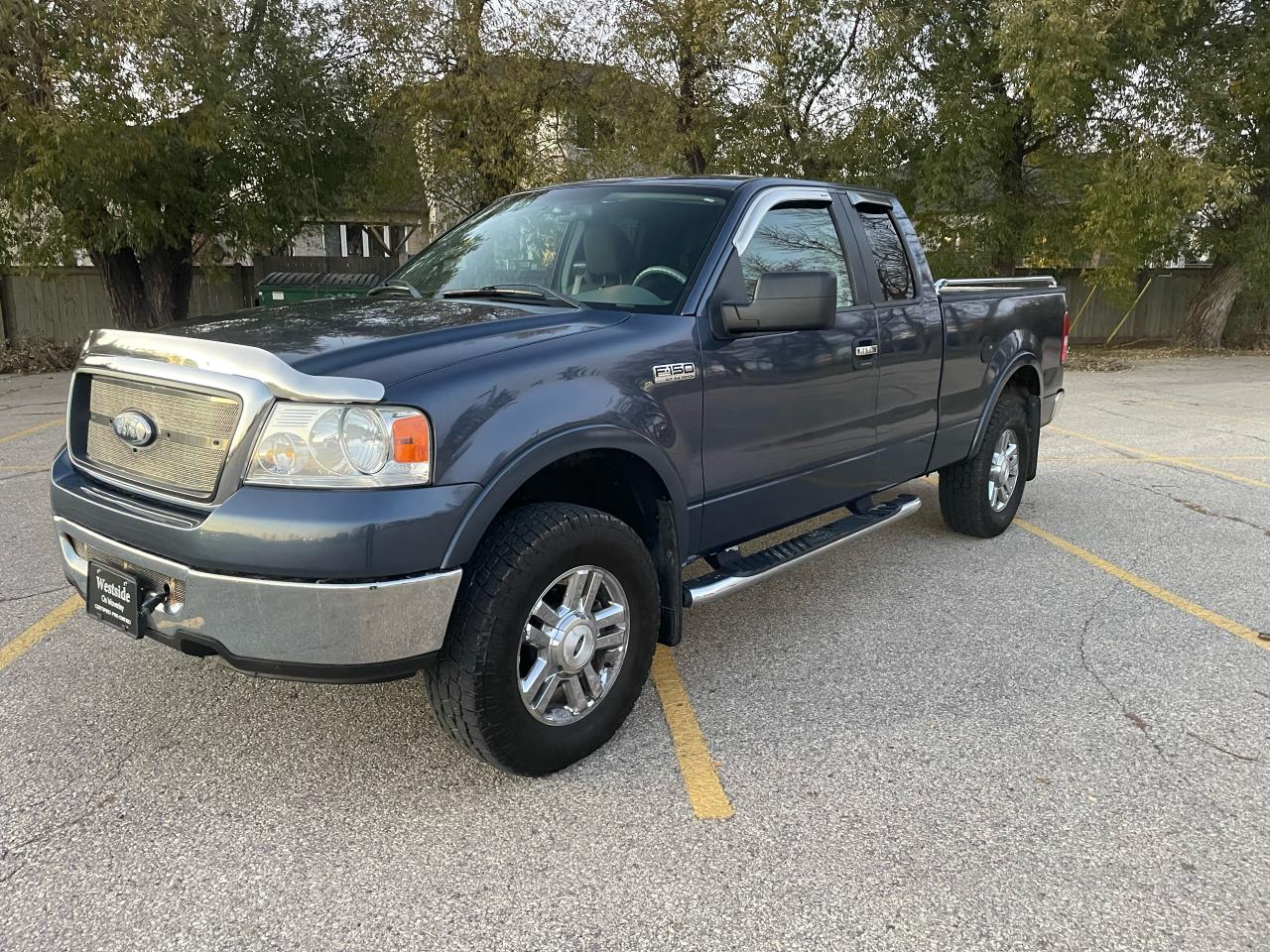 <p>This 2006 Ford F-150 XLT is a dependable and capable truck, perfect for those who need a reliable workhorse or a capable off-road companion. With its robust 5.4L 8-cylinder engine and 4-wheel drive system, it handles tough jobs with ease and can tackle any terrain. The blue exterior and gray interior provide a classic and timeless look, while features like power windows, locks, and mirrors add convenience to every drive.</p><p>This F-150 XLT comes equipped with a wide range of features designed to enhance comfort and safety. With 196,000km on the odometer, its ready to tackle your next adventure. You can find this truck at Westside Sales, your trusted source for quality pre-owned vehicles.</p><p>Here are five of the features that make this F-150 XLT stand out:</p><ol><li><strong>Powerful 5.4L 8-cylinder Engine:</strong> This truck is built to handle any task with its robust engine, providing plenty of power for towing, hauling, and off-roading.</li><li><strong>4-Wheel Drive System:</strong> Experience confidence and control on any surface with the reliable 4-wheel drive system.</li><li><strong>Spacious and Comfortable Interior:</strong> With cloth seats and plenty of legroom, you and your passengers will enjoy every journey.</li><li><strong>Power Windows, Locks, and Mirrors:</strong> Convenience is at your fingertips with these essential features.</li><li><strong>Safety Features:</strong> Peace of mind comes standard with features like anti-lock brakes and airbags.</li><li><strong>Remote start:</strong> Ready for cooler conditions!</li></ol><p><!-- [if gte mso 9]><xml><br /><br />
 <o:OfficeDocumentSettings><br /><br />
  <o:AllowPNG/><br /><br />
 </o:OfficeDocumentSettings><br /><br />
</xml><![endif]--><!-- [if gte mso 9]><xml><br /><br />
 <w:WordDocument><br /><br />
  <w:View>Normal</w:View><br /><br />
  <w:Zoom>0</w:Zoom><br /><br />
  <w:TrackMoves/><br /><br />
  <w:TrackFormatting/><br /><br />
  <w:PunctuationKerning/><br /><br />
  <w:ValidateAgainstSchemas/><br /><br />
  <w:SaveIfXMLInvalid>false</w:SaveIfXMLInvalid><br /><br />
  <w:IgnoreMixedContent>false</w:IgnoreMixedContent><br /><br />
  <w:AlwaysShowPlaceholderText>false</w:AlwaysShowPlaceholderText><br /><br />
  <w:DoNotPromoteQF/><br /><br />
  <w:LidThemeOther>EN-US</w:LidThemeOther><br /><br />
  <w:LidThemeAsian>X-NONE</w:LidThemeAsian><br /><br />
  <w:LidThemeComplexScript>X-NONE</w:LidThemeComplexScript><br /><br />
  <w:Compatibility><br /><br />
   <w:BreakWrappedTables/><br /><br />
   <w:SnapToGridInCell/><br /><br />
   <w:WrapTextWithPunct/><br /><br />
   <w:UseAsianBreakRules/><br /><br />
   <w:DontGrowAutofit/><br /><br />
   <w:SplitPgBreakAndParaMark/><br /><br />
   <w:EnableOpenTypeKerning/><br /><br />
   <w:DontFlipMirrorIndents/><br /><br />
   <w:OverrideTableStyleHps/><br /><br />
  </w:Compatibility><br /><br />
  <m:mathPr><br /><br />
   <m:mathFont m:val=Cambria Math/><br /><br />
   <m:brkBin m:val=before/><br /><br />
   <m:brkBinSub m:val=--/><br /><br />
   <m:smallFrac m:val=off/><br /><br />
   <m:dispDef/><br /><br />
   <m:lMargin m:val=0/><br /><br />
   <m:rMargin m:val=0/><br /><br />
   <m:defJc m:val=centerGroup/><br /><br />
   <m:wrapIndent m:val=1440/><br /><br />
   <m:intLim m:val=subSup/><br /><br />
   <m:naryLim m:val=undOvr/><br /><br />
  </m:mathPr></w:WordDocument><br /><br />
</xml><![endif]--><!-- [if gte mso 9]><xml><br /><br />
 <w:LatentStyles DefLockedState=false DefUnhideWhenUsed=false<br /><br />
  DefSemiHidden=false DefQFormat=false DefPriority=99<br /><br />
  LatentStyleCount=376><br /><br />
  <w:LsdException Locked=false Priority=0 QFormat=true Name=Normal/><br /><br />
  <w:LsdException Locked=false Priority=9 QFormat=true Name=heading 1/><br /><br />
  <w:LsdException Locked=false Priority=9 SemiHidden=true<br /><br />
   UnhideWhenUsed=true QFormat=true Name=heading 2/><br /><br />
  <w:LsdException Locked=false Priority=9 SemiHidden=true<br /><br />
   UnhideWhenUsed=true QFormat=true Name=heading 3/><br /><br />
  <w:LsdException Locked=false Priority=9 SemiHidden=true<br /><br />
   UnhideWhenUsed=true QFormat=true Name=heading 4/><br /><br />
  <w:LsdException Locked=false Priority=9 SemiHidden=true<br /><br />
   UnhideWhenUsed=true QFormat=true Name=heading 5/><br /><br />
  <w:LsdException Locked=false Priority=9 SemiHidden=true<br /><br />
   UnhideWhenUsed=true QFormat=true Name=heading 6/><br /><br />
  <w:LsdException Locked=false Priority=9 SemiHidden=true<br /><br />
   UnhideWhenUsed=true QFormat=true Name=heading 7/><br /><br />
  <w:LsdException Locked=false Priority=9 SemiHidden=true<br /><br />
   UnhideWhenUsed=true QFormat=true Name=heading 8/><br /><br />
  <w:LsdException Locked=false Priority=9 SemiHidden=true<br /><br />
   UnhideWhenUsed=true QFormat=true Name=heading 9/><br /><br />
  <w:LsdException Locked=false SemiHidden=true UnhideWhenUsed=true<br /><br />
   Name=index 1/><br /><br />
  <w:LsdException Locked=false SemiHidden=true UnhideWhenUsed=true<br /><br />
   Name=index 2/><br /><br />
  <w:LsdException Locked=false SemiHidden=true UnhideWhenUsed=true<br /><br />
   Name=index 3/><br /><br />
  <w:LsdException Locked=false SemiHidden=true UnhideWhenUsed=true<br /><br />
   Name=index 4/><br /><br />
  <w:LsdException Locked=false SemiHidden=true UnhideWhenUsed=true<br /><br />
   Name=index 5/><br /><br />
  <w:LsdException Locked=false SemiHidden=true UnhideWhenUsed=true<br /><br />
   Name=index 6/><br /><br />
  <w:LsdException Locked=false SemiHidden=true UnhideWhenUsed=true<br /><br />
   Name=index 7/><br /><br />
  <w:LsdException Locked=false SemiHidden=true UnhideWhenUsed=true<br /><br />
   Name=index 8/><br /><br />
  <w:LsdException Locked=false SemiHidden=true UnhideWhenUsed=true<br /><br />
   Name=index 9/><br /><br />
  <w:LsdException Locked=false Priority=39 SemiHidden=true<br /><br />
   UnhideWhenUsed=true Name=toc 1/><br /><br />
  <w:LsdException Locked=false Priority=39 SemiHidden=true<br /><br />
   UnhideWhenUsed=true Name=toc 2/><br /><br />
  <w:LsdException Locked=false Priority=39 SemiHidden=true<br /><br />
   UnhideWhenUsed=true Name=toc 3/><br /><br />
  <w:LsdException Locked=false Priority=39 SemiHidden=true<br /><br />
   UnhideWhenUsed=true Name=toc 4/><br /><br />
  <w:LsdException Locked=false Priority=39 SemiHidden=true<br /><br />
   UnhideWhenUsed=true Name=toc 5/><br /><br />
  <w:LsdException Locked=false Priority=39 SemiHidden=true<br /><br />
   UnhideWhenUsed=true Name=toc 6/><br /><br />
  <w:LsdException Locked=false Priority=39 SemiHidden=true<br /><br />
   UnhideWhenUsed=true Name=toc 7/><br /><br />
  <w:LsdException Locked=false Priority=39 SemiHidden=true<br /><br />
   UnhideWhenUsed=true Name=toc 8/><br /><br />
  <w:LsdException Locked=false Priority=39 SemiHidden=true<br /><br />
   UnhideWhenUsed=true Name=toc 9/><br /><br />
  <w:LsdException Locked=false SemiHidden=true UnhideWhenUsed=true<br /><br />
   Name=Normal Indent/><br /><br />
  <w:LsdException Locked=false SemiHidden=true UnhideWhenUsed=true<br /><br />
   Name=footnote text/><br /><br />
  <w:LsdException Locked=false SemiHidden=true UnhideWhenUsed=true<br /><br />
   Name=annotation text/><br /><br />
  <w:LsdException Locked=false SemiHidden=true UnhideWhenUsed=true<br /><br />
   Name=header/><br /><br />
  <w:LsdException Locked=false SemiHidden=true UnhideWhenUsed=true<br /><br />
   Name=footer/><br /><br />
  <w:LsdException Locked=false SemiHidden=true UnhideWhenUsed=true<br /><br />
   Name=index heading/><br /><br />
  <w:LsdException Locked=false Priority=35 SemiHidden=true<br /><br />
   UnhideWhenUsed=true QFormat=true Name=caption/><br /><br />
  <w:LsdException Locked=false SemiHidden=true UnhideWhenUsed=true<br /><br />
   Name=table of figures/><br /><br />
  <w:LsdException Locked=false SemiHidden=true UnhideWhenUsed=true<br /><br />
   Name=envelope address/><br /><br />
  <w:LsdException Locked=false SemiHidden=true UnhideWhenUsed=true<br /><br />
   Name=envelope return/><br /><br />
  <w:LsdException Locked=false SemiHidden=true UnhideWhenUsed=true<br /><br />
   Name=footnote reference/><br /><br />
  <w:LsdException Locked=false SemiHidden=true UnhideWhenUsed=true<br /><br />
   Name=annotation reference/><br /><br />
  <w:LsdException Locked=false SemiHidden=true UnhideWhenUsed=true<br /><br />
   Name=line number/><br /><br />
  <w:LsdException Locked=false SemiHidden=true UnhideWhenUsed=true<br /><br />
   Name=page number/><br /><br />
  <w:LsdException Locked=false SemiHidden=true UnhideWhenUsed=true<br /><br />
   Name=endnote reference/><br /><br />
  <w:LsdException Locked=false SemiHidden=true UnhideWhenUsed=true<br /><br />
   Name=endnote text/><br /><br />
  <w:LsdException Locked=false SemiHidden=true UnhideWhenUsed=true<br /><br />
   Name=table of authorities/><br /><br />
  <w:LsdException Locked=false SemiHidden=true UnhideWhenUsed=true<br /><br />
   Name=macro/><br /><br />
  <w:LsdException Locked=false SemiHidden=true UnhideWhenUsed=true<br /><br />
   Name=toa heading/><br /><br />
  <w:LsdException Locked=false SemiHidden=true UnhideWhenUsed=true<br /><br />
   Name=List/><br /><br />
  <w:LsdException Locked=false SemiHidden=true UnhideWhenUsed=true<br /><br />
   Name=List Bullet/><br /><br />
  <w:LsdException Locked=false SemiHidden=true UnhideWhenUsed=true<br /><br />
   Name=List Number/><br /><br />
  <w:LsdException Locked=false SemiHidden=true UnhideWhenUsed=true<br /><br />
   Name=List 2/><br /><br />
  <w:LsdException Locked=false SemiHidden=true UnhideWhenUsed=true<br /><br />
   Name=List 3/><br /><br />
  <w:LsdException Locked=false SemiHidden=true UnhideWhenUsed=true<br /><br />
   Name=List 4/><br /><br />
  <w:LsdException Locked=false SemiHidden=true UnhideWhenUsed=true<br /><br />
   Name=List 5/><br /><br />
  <w:LsdException Locked=false SemiHidden=true UnhideWhenUsed=true<br /><br />
   Name=List Bullet 2/><br /><br />
  <w:LsdException Locked=false SemiHidden=true UnhideWhenUsed=true<br /><br />
   Name=List Bullet 3/><br /><br />
  <w:LsdException Locked=false SemiHidden=true UnhideWhenUsed=true<br /><br />
   Name=List Bullet 4/><br /><br />
  <w:LsdException Locked=false SemiHidden=true UnhideWhenUsed=true<br /><br />
   Name=List Bullet 5/><br /><br />
  <w:LsdException Locked=false SemiHidden=true UnhideWhenUsed=true<br /><br />
   Name=List Number 2/><br /><br />
  <w:LsdException Locked=false SemiHidden=true UnhideWhenUsed=true<br /><br />
   Name=List Number 3/><br /><br />
  <w:LsdException Locked=false SemiHidden=true UnhideWhenUsed=true<br /><br />
   Name=List Number 4/><br /><br />
  <w:LsdException Locked=false SemiHidden=true UnhideWhenUsed=true<br /><br />
   Name=List Number 5/><br /><br />
  <w:LsdException Locked=false Priority=10 QFormat=true Name=Title/><br /><br />
  <w:LsdException Locked=false SemiHidden=true UnhideWhenUsed=true<br /><br />
   Name=Closing/><br /><br />
  <w:LsdException Locked=false SemiHidden=true UnhideWhenUsed=true<br /><br />
   Name=Signature/><br /><br />
  <w:LsdException Locked=false Priority=1 SemiHidden=true<br /><br />
   UnhideWhenUsed=true Name=Default Paragraph Font/><br /><br />
  <w:LsdException Locked=false SemiHidden=true UnhideWhenUsed=true<br /><br />
   Name=Body Text/><br /><br />
  <w:LsdException Locked=false SemiHidden=true UnhideWhenUsed=true<br /><br />
   Name=Body Text Indent/><br /><br />
  <w:LsdException Locked=false SemiHidden=true UnhideWhenUsed=true<br /><br />
   Name=List Continue/><br /><br />
  <w:LsdException Locked=false SemiHidden=true UnhideWhenUsed=true<br /><br />
   Name=List Continue 2/><br /><br />
  <w:LsdException Locked=false SemiHidden=true UnhideWhenUsed=true<br /><br />
   Name=List Continue 3/><br /><br />
  <w:LsdException Locked=false SemiHidden=true UnhideWhenUsed=true<br /><br />
   Name=List Continue 4/><br /><br />
  <w:LsdException Locked=false SemiHidden=true UnhideWhenUsed=true<br /><br />
   Name=List Continue 5/><br /><br />
  <w:LsdException Locked=false SemiHidden=true UnhideWhenUsed=true<br /><br />
   Name=Message Header/><br /><br />
  <w:LsdException Locked=false Priority=11 QFormat=true Name=Subtitle/><br /><br />
  <w:LsdException Locked=false SemiHidden=true UnhideWhenUsed=true<br /><br />
   Name=Salutation/><br /><br />
  <w:LsdException Locked=false SemiHidden=true UnhideWhenUsed=true<br /><br />
   Name=Date/><br /><br />
  <w:LsdException Locked=false SemiHidden=true UnhideWhenUsed=true<br /><br />
   Name=Body Text First Indent/><br /><br />
  <w:LsdException Locked=false SemiHidden=true UnhideWhenUsed=true<br /><br />
   Name=Body Text First Indent 2/><br /><br />
  <w:LsdException Locked=false SemiHidden=true UnhideWhenUsed=true<br /><br />
   Name=Note Heading/><br /><br />
  <w:LsdException Locked=false SemiHidden=true UnhideWhenUsed=true<br /><br />
   Name=Body Text 2/><br /><br />
  <w:LsdException Locked=false SemiHidden=true UnhideWhenUsed=true<br /><br />
   Name=Body Text 3/><br /><br />
  <w:LsdException Locked=false SemiHidden=true UnhideWhenUsed=true<br /><br />
   Name=Body Text Indent 2/><br /><br />
  <w:LsdException Locked=false SemiHidden=true UnhideWhenUsed=true<br /><br />
   Name=Body Text Indent 3/><br /><br />
  <w:LsdException Locked=false SemiHidden=true UnhideWhenUsed=true<br /><br />
   Name=Block Text/><br /><br />
  <w:LsdException Locked=false SemiHidden=true UnhideWhenUsed=true<br /><br />
   Name=Hyperlink/><br /><br />
  <w:LsdException Locked=false SemiHidden=true UnhideWhenUsed=true<br /><br />
   Name=FollowedHyperlink/><br /><br />
  <w:LsdException Locked=false Priority=22 QFormat=true Name=Strong/><br /><br />
  <w:LsdException Locked=false Priority=20 QFormat=true Name=Emphasis/><br /><br />
  <w:LsdException Locked=false SemiHidden=true UnhideWhenUsed=true<br /><br />
   Name=Document Map/><br /><br />
  <w:LsdException Locked=false SemiHidden=true UnhideWhenUsed=true<br /><br />
   Name=Plain Text/><br /><br />
  <w:LsdException Locked=false SemiHidden=true UnhideWhenUsed=true<br /><br />
   Name=E-mail Signature/><br /><br />
  <w:LsdException Locked=false SemiHidden=true UnhideWhenUsed=true<br /><br />
   Name=HTML Top of Form/><br /><br />
  <w:LsdException Locked=false SemiHidden=true UnhideWhenUsed=true<br /><br />
   Name=HTML Bottom of Form/><br /><br />
  <w:LsdException Locked=false SemiHidden=true UnhideWhenUsed=true<br /><br />
   Name=Normal (Web)/><br /><br />
  <w:LsdException Locked=false SemiHidden=true UnhideWhenUsed=true<br /><br />
   Name=HTML Acronym/><br /><br />
  <w:LsdException Locked=false SemiHidden=true UnhideWhenUsed=true<br /><br />
   Name=HTML Address/><br /><br />
  <w:LsdException Locked=false SemiHidden=true UnhideWhenUsed=true<br /><br />
   Name=HTML Cite/><br /><br />
  <w:LsdException Locked=false SemiHidden=true UnhideWhenUsed=true<br /><br />
   Name=HTML Code/><br /><br />
  <w:LsdException Locked=false SemiHidden=true UnhideWhenUsed=true<br /><br />
   Name=HTML Definition/><br /><br />
  <w:LsdException Locked=false SemiHidden=true UnhideWhenUsed=true<br /><br />
   Name=HTML Keyboard/><br /><br />
  <w:LsdException Locked=false SemiHidden=true UnhideWhenUsed=true<br /><br />
   Name=HTML Preformatted/><br /><br />
  <w:LsdException Locked=false SemiHidden=true UnhideWhenUsed=true<br /><br />
   Name=HTML Sample/><br /><br />
  <w:LsdException Locked=false SemiHidden=true UnhideWhenUsed=true<br /><br />
   Name=HTML Typewriter/><br /><br />
  <w:LsdException Locked=false SemiHidden=true UnhideWhenUsed=true<br /><br />
   Name=HTML Variable/><br /><br />
  <w:LsdException Locked=false SemiHidden=true UnhideWhenUsed=true<br /><br />
   Name=Normal Table/><br /><br />
  <w:LsdException Locked=false SemiHidden=true UnhideWhenUsed=true<br /><br />
   Name=annotation subject/><br /><br />
  <w:LsdException Locked=false SemiHidden=true UnhideWhenUsed=true<br /><br />
   Name=No List/><br /><br />
  <w:LsdException Locked=false SemiHidden=true UnhideWhenUsed=true<br /><br />
   Name=Outline List 1/><br /><br />
  <w:LsdException Locked=false SemiHidden=true UnhideWhenUsed=true<br /><br />
   Name=Outline List 2/><br /><br />
  <w:LsdException Locked=false SemiHidden=true UnhideWhenUsed=true<br /><br />
   Name=Outline List 3/><br /><br />
  <w:LsdException Locked=false SemiHidden=true UnhideWhenUsed=true<br /><br />
   Name=Table Simple 1/><br /><br />
  <w:LsdException Locked=false SemiHidden=true UnhideWhenUsed=true<br /><br />
   Name=Table Simple 2/><br /><br />
  <w:LsdException Locked=false SemiHidden=true UnhideWhenUsed=true<br /><br />
   Name=Table Simple 3/><br /><br />
  <w:LsdException Locked=false SemiHidden=true UnhideWhenUsed=true<br /><br />
   Name=Table Classic 1/><br /><br />
  <w:LsdException Locked=false SemiHidden=true UnhideWhenUsed=true<br /><br />
   Name=Table Classic 2/><br /><br />
  <w:LsdException Locked=false SemiHidden=true UnhideWhenUsed=true<br /><br />
   Name=Table Classic 3/><br /><br />
  <w:LsdException Locked=false SemiHidden=true UnhideWhenUsed=true<br /><br />
   Name=Table Classic 4/><br /><br />
  <w:LsdException Locked=false SemiHidden=true UnhideWhenUsed=true<br /><br />
   Name=Table Colorful 1/><br /><br />
  <w:LsdException Locked=false SemiHidden=true UnhideWhenUsed=true<br /><br />
   Name=Table Colorful 2/><br /><br />
  <w:LsdException Locked=false SemiHidden=true UnhideWhenUsed=true<br /><br />
   Name=Table Colorful 3/><br /><br />
  <w:LsdException Locked=false SemiHidden=true UnhideWhenUsed=true<br /><br />
   Name=Table Columns 1/><br /><br />
  <w:LsdException Locked=false SemiHidden=true UnhideWhenUsed=true<br /><br />
   Name=Table Columns 2/><br /><br />
  <w:LsdException Locked=false SemiHidden=true UnhideWhenUsed=true<br /><br />
   Name=Table Columns 3/><br /><br />
  <w:LsdException Locked=false SemiHidden=true UnhideWhenUsed=true<br /><br />
   Name=Table Columns 4/><br /><br />
  <w:LsdException Locked=false SemiHidden=true UnhideWhenUsed=true<br /><br />
   Name=Table Columns 5/><br /><br />
  <w:LsdException Locked=false SemiHidden=true UnhideWhenUsed=true<br /><br />
   Name=Table Grid 1/><br /><br />
  <w:LsdException Locked=false SemiHidden=true UnhideWhenUsed=true<br /><br />
   Name=Table Grid 2/><br /><br />
  <w:LsdException Locked=false SemiHidden=true UnhideWhenUsed=true<br /><br />
   Name=Table Grid 3/><br /><br />
  <w:LsdException Locked=false SemiHidden=true UnhideWhenUsed=true<br /><br />
   Name=Table Grid 4/><br /><br />
  <w:LsdException Locked=false SemiHidden=true UnhideWhenUsed=true<br /><br />
   Name=Table Grid 5/><br /><br />
  <w:LsdException Locked=false SemiHidden=true UnhideWhenUsed=true<br /><br />
   Name=Table Grid 6/><br /><br />
  <w:LsdException Locked=false SemiHidden=true UnhideWhenUsed=true<br /><br />
   Name=Table Grid 7/><br /><br />
  <w:LsdException Locked=false SemiHidden=true UnhideWhenUsed=true<br /><br />
   Name=Table Grid 8/><br /><br />
  <w:LsdException Locked=false SemiHidden=true UnhideWhenUsed=true<br /><br />
   Name=Table List 1/><br /><br />
  <w:LsdException Locked=false SemiHidden=true UnhideWhenUsed=true<br /><br />
   Name=Table List 2/><br /><br />
  <w:LsdException Locked=false SemiHidden=true UnhideWhenUsed=true<br /><br />
   Name=Table List 3/><br /><br />
  <w:LsdException Locked=false SemiHidden=true UnhideWhenUsed=true<br /><br />
   Name=Table List 4/><br /><br />
  <w:LsdException Locked=false SemiHidden=true UnhideWhenUsed=true<br /><br />
   Name=Table List 5/><br /><br />
  <w:LsdException Locked=false SemiHidden=true UnhideWhenUsed=true<br /><br />
   Name=Table List 6/><br /><br />
  <w:LsdException Locked=false SemiHidden=true UnhideWhenUsed=true<br /><br />
   Name=Table List 7/><br /><br />
  <w:LsdException Locked=false SemiHidden=true UnhideWhenUsed=true<br /><br />
   Name=Table List 8/><br /><br />
  <w:LsdException Locked=false SemiHidden=true UnhideWhenUsed=true<br /><br />
   Name=Table 3D effects 1/><br /><br />
  <w:LsdException Locked=false SemiHidden=true UnhideWhenUsed=true<br /><br />
   Name=Table 3D effects 2/><br /><br />
  <w:LsdException Locked=false SemiHidden=true UnhideWhenUsed=true<br /><br />
   Name=Table 3D effects 3/><br /><br />
  <w:LsdException Locked=false SemiHidden=true UnhideWhenUsed=true<br /><br />
   Name=Table Contemporary/><br /><br />
  <w:LsdException Locked=false SemiHidden=true UnhideWhenUsed=true<br /><br />
   Name=Table Elegant/><br /><br />
  <w:LsdException Locked=false SemiHidden=true UnhideWhenUsed=true<br /><br />
   Name=Table Professional/><br /><br />
  <w:LsdException Locked=false SemiHidden=true UnhideWhenUsed=true<br /><br />
   Name=Table Subtle 1/><br /><br />
  <w:LsdException Locked=false SemiHidden=true UnhideWhenUsed=true<br /><br />
   Name=Table Subtle 2/><br /><br />
  <w:LsdException Locked=false SemiHidden=true UnhideWhenUsed=true<br /><br />
   Name=Table Web 1/><br /><br />
  <w:LsdException Locked=false SemiHidden=true UnhideWhenUsed=true<br /><br />
   Name=Table Web 2/><br /><br />
  <w:LsdException Locked=false SemiHidden=true UnhideWhenUsed=true<br /><br />
   Name=Table Web 3/><br /><br />
  <w:LsdException Locked=false SemiHidden=true UnhideWhenUsed=true<br /><br />
   Name=Balloon Text/><br /><br />
  <w:LsdException Locked=false Priority=39 Name=Table Grid/><br /><br />
  <w:LsdException Locked=false SemiHidden=true UnhideWhenUsed=true<br /><br />
   Name=Table Theme/><br /><br />
  <w:LsdException Locked=false SemiHidden=true Name=Placeholder Text/><br /><br />
  <w:LsdException Locked=false Priority=1 QFormat=true Name=No Spacing/><br /><br />
  <w:LsdException Locked=false Priority=60 Name=Light Shading/><br /><br />
  <w:LsdException Locked=false Priority=61 Name=Light List/><br /><br />
  <w:LsdException Locked=false Priority=62 Name=Light Grid/><br /><br />
  <w:LsdException Locked=false Priority=63 Name=Medium Shading 1/><br /><br />
  <w:LsdException Locked=false Priority=64 Name=Medium Shading 2/><br /><br />
  <w:LsdException Locked=false Priority=65 Name=Medium List 1/><br /><br />
  <w:LsdException Locked=false Priority=66 Name=Medium List 2/><br /><br />
  <w:LsdException Locked=false Priority=67 Name=Medium Grid 1/><br /><br />
  <w:LsdException Locked=false Priority=68 Name=Medium Grid 2/><br /><br />
  <w:LsdException Locked=false Priority=69 Name=Medium Grid 3/><br /><br />
  <w:LsdException Locked=false Priority=70 Name=Dark List/><br /><br />
  <w:LsdException Locked=false Priority=71 Name=Colorful Shading/><br /><br />
  <w:LsdException Locked=false Priority=72 Name=Colorful List/><br /><br />
  <w:LsdException Locked=false Priority=73 Name=Colorful Grid/><br /><br />
  <w:LsdException Locked=false Priority=60 Name=Light Shading Accent 1/><br /><br />
  <w:LsdException Locked=false Priority=61 Name=Light List Accent 1/><br /><br />
  <w:LsdException Locked=false Priority=62 Name=Light Grid Accent 1/><br /><br />
  <w:LsdException Locked=false Priority=63 Name=Medium Shading 1 Accent 1/><br /><br />
  <w:LsdException Locked=false Priority=64 Name=Medium Shading 2 Accent 1/><br /><br />
  <w:LsdException Locked=false Priority=65 Name=Medium List 1 Accent 1/><br /><br />
  <w:LsdException Locked=false SemiHidden=true Name=Revision/><br /><br />
  <w:LsdException Locked=false Priority=34 QFormat=true<br /><br />
   Name=List Paragraph/><br /><br />
  <w:LsdException Locked=false Priority=29 QFormat=true Name=Quote/><br /><br />
  <w:LsdException Locked=false Priority=30 QFormat=true<br /><br />
   Name=Intense Quote/><br /><br />
  <w:LsdException Locked=false Priority=66 Name=Medium List 2 Accent 1/><br /><br />
  <w:LsdException Locked=false Priority=67 Name=Medium Grid 1 Accent 1/><br /><br />
  <w:LsdException Locked=false Priority=68 Name=Medium Grid 2 Accent 1/><br /><br />
  <w:LsdException Locked=false Priority=69 Name=Medium Grid 3 Accent 1/><br /><br />
  <w:LsdException Locked=false Priority=70 Name=Dark List Accent 1/><br /><br />
  <w:LsdException Locked=false Priority=71 Name=Colorful Shading Accent 1/><br /><br />
  <w:LsdException Locked=false Priority=72 Name=Colorful List Accent 1/><br /><br />
  <w:LsdException Locked=false Priority=73 Name=Colorful Grid Accent 1/><br /><br />
  <w:LsdException Locked=false Priority=60 Name=Light Shading Accent 2/><br /><br />
  <w:LsdException Locked=false Priority=61 Name=Light List Accent 2/><br /><br />
  <w:LsdException Locked=false Priority=62 Name=Light Grid Accent 2/><br /><br />
  <w:LsdException Locked=false Priority=63 Name=Medium Shading 1 Accent 2/><br /><br />
  <w:LsdException Locked=false Priority=64 Name=Medium Shading 2 Accent 2/><br /><br />
  <w:LsdException Locked=false Priority=65 Name=Medium List 1 Accent 2/><br /><br />
  <w:LsdException Locked=false Priority=66 Name=Medium List 2 Accent 2/><br /><br />
  <w:LsdException Locked=false Priority=67 Name=Medium Grid 1 Accent 2/><br /><br />
  <w:LsdException Locked=false Priority=68 Name=Medium Grid 2 Accent 2/><br /><br />
  <w:LsdException Locked=false Priority=69 Name=Medium Grid 3 Accent 2/><br /><br />
  <w:LsdException Locked=false Priority=70 Name=Dark List Accent 2/><br /><br />
  <w:LsdException Locked=false Priority=71 Name=Colorful Shading Accent 2/><br /><br />
  <w:LsdException Locked=false Priority=72 Name=Colorful List Accent 2/><br /><br />
  <w:LsdException Locked=false Priority=73 Name=Colorful Grid Accent 2/><br /><br />
  <w:LsdException Locked=false Priority=60 Name=Light Shading Accent 3/><br /><br />
  <w:LsdException Locked=false Priority=61 Name=Light List Accent 3/><br /><br />
  <w:LsdException Locked=false Priority=62 Name=Light Grid Accent 3/><br /><br />
  <w:LsdException Locked=false Priority=63 Name=Medium Shading 1 Accent 3/><br /><br />
  <w:LsdException Locked=false Priority=64 Name=Medium Shading 2 Accent 3/><br /><br />
  <w:LsdException Locked=false Priority=65 Name=Medium List 1 Accent 3/><br /><br />
  <w:LsdException Locked=false Priority=66 Name=Medium List 2 Accent 3/><br /><br />
  <w:LsdException Locked=false Priority=67 Name=Medium Grid 1 Accent 3/><br /><br />
  <w:LsdException Locked=false Priority=68 Name=Medium Grid 2 Accent 3/><br /><br />
  <w:LsdException Locked=false Priority=69 Name=Medium Grid 3 Accent 3/><br /><br />
  <w:LsdException Locked=false Priority=70 Name=Dark List Accent 3/><br /><br />
  <w:LsdException Locked=false Priority=71 Name=Colorful Shading Accent 3/><br /><br />
  <w:LsdException Locked=false Priority=72 Name=Colorful List Accent 3/><br /><br />
  <w:LsdException Locked=false Priority=73 Name=Colorful Grid Accent 3/><br /><br />
  <w:LsdException Locked=false Priority=60 Name=Light Shading Accent 4/><br /><br />
  <w:LsdException Locked=false Priority=61 Name=Light List Accent 4/><br /><br />
  <w:LsdException Locked=false Priority=62 Name=Light Grid Accent 4/><br /><br />
  <w:LsdException Locked=false Priority=63 Name=Medium Shading 1 Accent 4/><br /><br />
  <w:LsdException Locked=false Priority=64 Name=Medium Shading 2 Accent 4/><br /><br />
  <w:LsdException Locked=false Priority=65 Name=Medium List 1 Accent 4/><br /><br />
  <w:LsdException Locked=false Priority=66 Name=Medium List 2 Accent 4/><br /><br />
  <w:LsdException Locked=false Priority=67 Name=Medium Grid 1 Accent 4/><br /><br />
  <w:LsdException Locked=false Priority=68 Name=Medium Grid 2 Accent 4/><br /><br />
  <w:LsdException Locked=false Priority=69 Name=Medium Grid 3 Accent 4/><br /><br />
  <w:LsdException Locked=false Priority=70 Name=Dark List Accent 4/><br /><br />
  <w:LsdException Locked=false Priority=71 Name=Colorful Shading Accent 4/><br /><br />
  <w:LsdException Locked=false Priority=72 Name=Colorful List Accent 4/><br /><br />
  <w:LsdException Locked=false Priority=73 Name=Colorful Grid Accent 4/><br /><br />
  <w:LsdException Locked=false Priority=60 Name=Light Shading Accent 5/><br /><br />
  <w:LsdException Locked=false Priority=61 Name=Light List Accent 5/><br /><br />
  <w:LsdException Locked=false Priority=62 Name=Light Grid Accent 5/><br /><br />
  <w:LsdException Locked=false Priority=63 Name=Medium Shading 1 Accent 5/><br /><br />
  <w:LsdException Locked=false Priority=64 Name=Medium Shading 2 Accent 5/><br /><br />
  <w:LsdException Locked=false Priority=65 Name=Medium List 1 Accent 5/><br /><br />
  <w:LsdException Locked=false Priority=66 Name=Medium List 2 Accent 5/><br /><br />
  <w:LsdException Locked=false Priority=67 Name=Medium Grid 1 Accent 5/><br /><br />
  <w:LsdException Locked=false Priority=68 Name=Medium Grid 2 Accent 5/><br /><br />
  <w:LsdException Locked=false Priority=69 Name=Medium Grid 3 Accent 5/><br /><br />
  <w:LsdException Locked=false Priority=70 Name=Dark List Accent 5/><br /><br />
  <w:LsdException Locked=false Priority=71 Name=Colorful Shading Accent 5/><br /><br />
  <w:LsdException Locked=false Priority=72 Name=Colorful List Accent 5/><br /><br />
  <w:LsdException Locked=false Priority=73 Name=Colorful Grid Accent 5/><br /><br />
  <w:LsdException Locked=false Priority=60 Name=Light Shading Accent 6/><br /><br />
  <w:LsdException Locked=false Priority=61 Name=Light List Accent 6/><br /><br />
  <w:LsdException Locked=false Priority=62 Name=Light Grid Accent 6/><br /><br />
  <w:LsdException Locked=false Priority=63 Name=Medium Shading 1 Accent 6/><br /><br />
  <w:LsdException Locked=false Priority=64 Name=Medium Shading 2 Accent 6/><br /><br />
  <w:LsdException Locked=false Priority=65 Name=Medium List 1 Accent 6/><br /><br />
  <w:LsdException Locked=false Priority=66 Name=Medium List 2 Accent 6/><br /><br />
  <w:LsdException Locked=false Priority=67 Name=Medium Grid 1 Accent 6/><br /><br />
  <w:LsdException Locked=false Priority=68 Name=Medium Grid 2 Accent 6/><br /><br />
  <w:LsdException Locked=false Priority=69 Name=Medium Grid 3 Accent 6/><br /><br />
  <w:LsdException Locked=false Priority=70 Name=Dark List Accent 6/><br /><br />
  <w:LsdException Locked=false Priority=71 Name=Colorful Shading Accent 6/><br /><br />
  <w:LsdException Locked=false Priority=72 Name=Colorful List Accent 6/><br /><br />
  <w:LsdException Locked=false Priority=73 Name=Colorful Grid Accent 6/><br /><br />
  <w:LsdException Locked=false Priority=19 QFormat=true<br /><br />
   Name=Subtle Emphasis/><br /><br />
  <w:LsdException Locked=false Priority=21 QFormat=true<br /><br />
   Name=Intense Emphasis/><br /><br />
  <w:LsdException Locked=false Priority=31 QFormat=true<br /><br />
   Name=Subtle Reference/><br /><br />
  <w:LsdException Locked=false Priority=32 QFormat=true<br /><br />
   Name=Intense Reference/><br /><br />
  <w:LsdException Locked=false Priority=33 QFormat=true Name=Book Title/><br /><br />
  <w:LsdException Locked=false Priority=37 SemiHidden=true<br /><br />
   UnhideWhenUsed=true Name=Bibliography/><br /><br />
  <w:LsdException Locked=false Priority=39 SemiHidden=true<br /><br />
   UnhideWhenUsed=true QFormat=true Name=TOC Heading/><br /><br />
  <w:LsdException Locked=false Priority=41 Name=Plain Table 1/><br /><br />
  <w:LsdException Locked=false Priority=42 Name=Plain Table 2/><br /><br />
  <w:LsdException Locked=false Priority=43 Name=Plain Table 3/><br /><br />
  <w:LsdException Locked=false Priority=44 Name=Plain Table 4/><br /><br />
  <w:LsdException Locked=false Priority=45 Name=Plain Table 5/><br /><br />
  <w:LsdException Locked=false Priority=40 Name=Grid Table Light/><br /><br />
  <w:LsdException Locked=false Priority=46 Name=Grid Table 1 Light/><br /><br />
  <w:LsdException Locked=false Priority=47 Name=Grid Table 2/><br /><br />
  <w:LsdException Locked=false Priority=48 Name=Grid Table 3/><br /><br />
  <w:LsdException Locked=false Priority=49 Name=Grid Table 4/><br /><br />
  <w:LsdException Locked=false Priority=50 Name=Grid Table 5 Dark/><br /><br />
  <w:LsdException Locked=false Priority=51 Name=Grid Table 6 Colorful/><br /><br />
  <w:LsdException Locked=false Priority=52 Name=Grid Table 7 Colorful/><br /><br />
  <w:LsdException Locked=false Priority=46<br /><br />
   Name=Grid Table 1 Light Accent 1/><br /><br />
  <w:LsdException Locked=false Priority=47 Name=Grid Table 2 Accent 1/><br /><br />
  <w:LsdException Locked=false Priority=48 Name=Grid Table 3 Accent 1/><br /><br />
  <w:LsdException Locked=false Priority=49 Name=Grid Table 4 Accent 1/><br /><br />
  <w:LsdException Locked=false Priority=50 Name=Grid Table 5 Dark Accent 1/><br /><br />
  <w:LsdException Locked=false Priority=51<br /><br />
   Name=Grid Table 6 Colorful Accent 1/><br /><br />
  <w:LsdException Locked=false Priority=52<br /><br />
   Name=Grid Table 7 Colorful Accent 1/><br /><br />
  <w:LsdException Locked=false Priority=46<br /><br />
   Name=Grid Table 1 Light Accent 2/><br /><br />
  <w:LsdException Locked=false Priority=47 Name=Grid Table 2 Accent 2/><br /><br />
  <w:LsdException Locked=false Priority=48 Name=Grid Table 3 Accent 2/><br /><br />
  <w:LsdException Locked=false Priority=49 Name=Grid Table 4 Accent 2/><br /><br />
  <w:LsdException Locked=false Priority=50 Name=Grid Table 5 Dark Accent 2/><br /><br />
  <w:LsdException Locked=false Priority=51<br /><br />
   Name=Grid Table 6 Colorful Accent 2/><br /><br />
  <w:LsdException Locked=false Priority=52<br /><br />
   Name=Grid Table 7 Colorful Accent 2/><br /><br />
  <w:LsdException Locked=false Priority=46<br /><br />
   Name=Grid Table 1 Light Accent 3/><br /><br />
  <w:LsdException Locked=false Priority=47 Name=Grid Table 2 Accent 3/><br /><br />
  <w:LsdException Locked=false Priority=48 Name=Grid Table 3 Accent 3/><br /><br />
  <w:LsdException Locked=false Priority=49 Name=Grid Table 4 Accent 3/><br /><br />
  <w:LsdException Locked=false Priority=50 Name=Grid Table 5 Dark Accent 3/><br /><br />
  <w:LsdException Locked=false Priority=51<br /><br />
   Name=Grid Table 6 Colorful Accent 3/><br /><br />
  <w:LsdException Locked=false Priority=52<br /><br />
   Name=Grid Table 7 Colorful Accent 3/><br /><br />
  <w:LsdException Locked=false Priority=46<br /><br />
   Name=Grid Table 1 Light Accent 4/><br /><br />
  <w:LsdException Locked=false Priority=47 Name=Grid Table 2 Accent 4/><br /><br />
  <w:LsdException Locked=false Priority=48 Name=Grid Table 3 Accent 4/><br /><br />
  <w:LsdException Locked=false Priority=49 Name=Grid Table 4 Accent 4/><br /><br />
  <w:LsdException Locked=false Priority=50 Name=Grid Table 5 Dark Accent 4/><br /><br />
  <w:LsdException Locked=false Priority=51<br /><br />
   Name=Grid Table 6 Colorful Accent 4/><br /><br />
  <w:LsdException Locked=false Priority=52<br /><br />
   Name=Grid Table 7 Colorful Accent 4/><br /><br />
  <w:LsdException Locked=false Priority=46<br /><br />
   Name=Grid Table 1 Light Accent 5/><br /><br />
  <w:LsdException Locked=false Priority=47 Name=Grid Table 2 Accent 5/><br /><br />
  <w:LsdException Locked=false Priority=48 Name=Grid Table 3 Accent 5/><br /><br />
  <w:LsdException Locked=false Priority=49 Name=Grid Table 4 Accent 5/><br /><br />
  <w:LsdException Locked=false Priority=50 Name=Grid Table 5 Dark Accent 5/><br /><br />
  <w:LsdException Locked=false Priority=51<br /><br />
   Name=Grid Table 6 Colorful Accent 5/><br /><br />
  <w:LsdException Locked=false Priority=52<br /><br />
   Name=Grid Table 7 Colorful Accent 5/><br /><br />
  <w:LsdException Locked=false Priority=46<br /><br />
   Name=Grid Table 1 Light Accent 6/><br /><br />
  <w:LsdException Locked=false Priority=47 Name=Grid Table 2 Accent 6/><br /><br />
  <w:LsdException Locked=false Priority=48 Name=Grid Table 3 Accent 6/><br /><br />
  <w:LsdException Locked=false Priority=49 Name=Grid Table 4 Accent 6/><br /><br />
  <w:LsdException Locked=false Priority=50 Name=Grid Table 5 Dark Accent 6/><br /><br />
  <w:LsdException Locked=false Priority=51<br /><br />
   Name=Grid Table 6 Colorful Accent 6/><br /><br />
  <w:LsdException Locked=false Priority=52<br /><br />
   Name=Grid Table 7 Colorful Accent 6/><br /><br />
  <w:LsdException Locked=false Priority=46 Name=List Table 1 Light/><br /><br />
  <w:LsdException Locked=false Priority=47 Name=List Table 2/><br /><br />
  <w:LsdException Locked=false Priority=48 Name=List Table 3/><br /><br />
  <w:LsdException Locked=false Priority=49 Name=List Table 4/><br /><br />
  <w:LsdException Locked=false Priority=50 Name=List Table 5 Dark/><br /><br />
  <w:LsdException Locked=false Priority=51 Name=List Table 6 Colorful/><br /><br />
  <w:LsdException Locked=false Priority=52 Name=List Table 7 Colorful/><br /><br />
  <w:LsdException Locked=false Priority=46<br /><br />
   Name=List Table 1 Light Accent 1/><br /><br />
  <w:LsdException Locked=false Priority=47 Name=List Table 2 Accent 1/><br /><br />
  <w:LsdException Locked=false Priority=48 Name=List Table 3 Accent 1/><br /><br />
  <w:LsdException Locked=false Priority=49 Name=List Table 4 Accent 1/><br /><br />
  <w:LsdException Locked=false Priority=50 Name=List Table 5 Dark Accent 1/><br /><br />
  <w:LsdException Locked=false Priority=51<br /><br />
   Name=List Table 6 Colorful Accent 1/><br /><br />
  <w:LsdException Locked=false Priority=52<br /><br />
   Name=List Table 7 Colorful Accent 1/><br /><br />
  <w:LsdException Locked=false Priority=46<br /><br />
   Name=List Table 1 Light Accent 2/><br /><br />
  <w:LsdException Locked=false Priority=47 Name=List Table 2 Accent 2/><br /><br />
  <w:LsdException Locked=false Priority=48 Name=List Table 3 Accent 2/><br /><br />
  <w:LsdException Locked=false Priority=49 Name=List Table 4 Accent 2/><br /><br />
  <w:LsdException Locked=false Priority=50 Name=List Table 5 Dark Accent 2/><br /><br />
  <w:LsdException Locked=false Priority=51<br /><br />
   Name=List Table 6 Colorful Accent 2/><br /><br />
  <w:LsdException Locked=false Priority=52<br /><br />
   Name=List Table 7 Colorful Accent 2/><br /><br />
  <w:LsdException Locked=false Priority=46<br /><br />
   Name=List Table 1 Light Accent 3/><br /><br />
  <w:LsdException Locked=false Priority=47 Name=List Table 2 Accent 3/><br /><br />
  <w:LsdException Locked=false Priority=48 Name=List Table 3 Accent 3/><br /><br />
  <w:LsdException Locked=false Priority=49 Name=List Table 4 Accent 3/><br /><br />
  <w:LsdException Locked=false Priority=50 Name=List Table 5 Dark Accent 3/><br /><br />
  <w:LsdException Locked=false Priority=51<br /><br />
   Name=List Table 6 Colorful Accent 3/><br /><br />
  <w:LsdException Locked=false Priority=52<br /><br />
   Name=List Table 7 Colorful Accent 3/><br /><br />
  <w:LsdException Locked=false Priority=46<br /><br />
   Name=List Table 1 Light Accent 4/><br /><br />
  <w:LsdException Locked=false Priority=47 Name=List Table 2 Accent 4/><br /><br />
  <w:LsdException Locked=false Priority=48 Name=List Table 3 Accent 4/><br /><br />
  <w:LsdException Locked=false Priority=49 Name=List Table 4 Accent 4/><br /><br />
  <w:LsdException Locked=false Priority=50 Name=List Table 5 Dark Accent 4/><br /><br />
  <w:LsdException Locked=false Priority=51<br /><br />
   Name=List Table 6 Colorful Accent 4/><br /><br />
  <w:LsdException Locked=false Priority=52<br /><br />
   Name=List Table 7 Colorful Accent 4/><br /><br />
  <w:LsdException Locked=false Priority=46<br /><br />
   Name=List Table 1 Light Accent 5/><br /><br />
  <w:LsdException Locked=false Priority=47 Name=List Table 2 Accent 5/><br /><br />
  <w:LsdException Locked=false Priority=48 Name=List Table 3 Accent 5/><br /><br />
  <w:LsdException Locked=false Priority=49 Name=List Table 4 Accent 5/><br /><br />
  <w:LsdException Locked=false Priority=50 Name=List Table 5 Dark Accent 5/><br /><br />
  <w:LsdException Locked=false Priority=51<br /><br />
   Name=List Table 6 Colorful Accent 5/><br /><br />
  <w:LsdException Locked=false Priority=52<br /><br />
   Name=List Table 7 Colorful Accent 5/><br /><br />
  <w:LsdException Locked=false Priority=46<br /><br />
   Name=List Table 1 Light Accent 6/><br /><br />
  <w:LsdException Locked=false Priority=47 Name=List Table 2 Accent 6/><br /><br />
  <w:LsdException Locked=false Priority=48 Name=List Table 3 Accent 6/><br /><br />
  <w:LsdException Locked=false Priority=49 Name=List Table 4 Accent 6/><br /><br />
  <w:LsdException Locked=false Priority=50 Name=List Table 5 Dark Accent 6/><br /><br />
  <w:LsdException Locked=false Priority=51<br /><br />
   Name=List Table 6 Colorful Accent 6/><br /><br />
  <w:LsdException Locked=false Priority=52<br /><br />
   Name=List Table 7 Colorful Accent 6/><br /><br />
  <w:LsdException Locked=false SemiHidden=true UnhideWhenUsed=true<br /><br />
   Name=Mention/><br /><br />
  <w:LsdException Locked=false SemiHidden=true UnhideWhenUsed=true<br /><br />
   Name=Smart Hyperlink/><br /><br />
  <w:LsdException Locked=false SemiHidden=true UnhideWhenUsed=true<br /><br />
   Name=Hashtag/><br /><br />
  <w:LsdException Locked=false SemiHidden=true UnhideWhenUsed=true<br /><br />
   Name=Unresolved Mention/><br /><br />
  <w:LsdException Locked=false SemiHidden=true UnhideWhenUsed=true<br /><br />
   Name=Smart Link/><br /><br />
 </w:LatentStyles><br /><br />
</xml><![endif]--><!-- [if gte mso 10]><br /><br />
<style><br /><br />
 /* Style Definitions */<br /><br />
 table.MsoNormalTable<br /><br />
	{mso-style-name:Table Normal;<br /><br />
	mso-tstyle-rowband-size:0;<br /><br />
	mso-tstyle-colband-size:0;<br /><br />
	mso-style-noshow:yes;<br /><br />
	mso-style-priority:99;<br /><br />
	mso-style-parent:;<br /><br />
	mso-padding-alt:0in 5.4pt 0in 5.4pt;<br /><br />
	mso-para-margin-top:0in;<br /><br />
	mso-para-margin-right:0in;<br /><br />
	mso-para-margin-bottom:8.0pt;<br /><br />
	mso-para-margin-left:0in;<br /><br />
	line-height:107%;<br /><br />
	mso-pagination:widow-orphan;<br /><br />
	font-size:11.0pt;<br /><br />
	font-family:Calibri,sans-serif;<br /><br />
	mso-ascii-font-family:Calibri;<br /><br />
	mso-ascii-theme-font:minor-latin;<br /><br />
	mso-hansi-font-family:Calibri;<br /><br />
	mso-hansi-theme-font:minor-latin;<br /><br />
	mso-bidi-font-family:Times New Roman;<br /><br />
	mso-bidi-theme-font:minor-bidi;<br /><br />
	mso-font-kerning:1.0pt;<br /><br />
	mso-ligatures:standardcontextual;}<br /><br />
</style><br /><br />
<![endif]--></p><p>1461 Waverley Street 204 488 3793. All vehicles safety certified and serviced, licensed technician on staff . Buy with confidence, We are one of the most established used car dealerships in Winnipeg. Come check us out... theres a reason we have been around since 1985 at the same location.<span style=mso-spacerun: yes;>    </span>See our other great deals at WWW.Westsidesales.CA Apply for financing on our website.<span style=mso-spacerun: yes;>  </span>Check us out on facebook and instagram @westsidesale<span style=mso-spacerun: yes;>   </span>DP#9491</p><p><em>Pow</em><em>ered by AutoIntelligence™ AI</em></p>