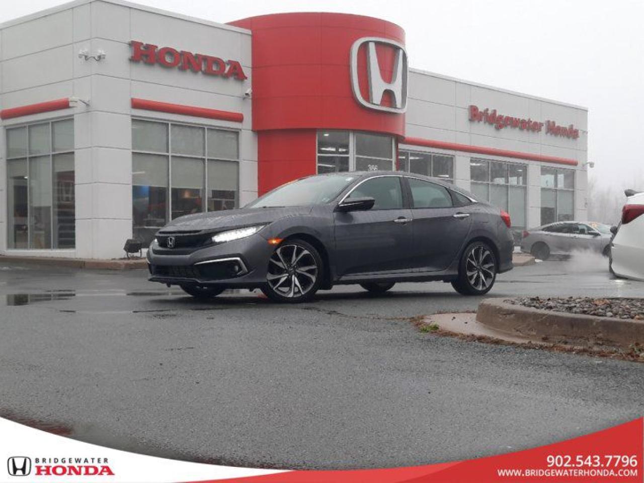 New Price! Recent Arrival! One Owner!! All Services Done At Honda !!Odometer is 33048 kilometers below market average! Nh797m 2020 Honda Civic Touring FWD CVT 1.5L I4 DOHC 16V Bridgewater Honda, Located in Bridgewater Nova Scotia.Remote Starter, Black Leather, 18 Aluminum Alloy Wheels, 4-Wheel Disc Brakes, Air Conditioning, Alloy wheels, Apple CarPlay/Android Auto, Auto High-beam Headlights, Auto-dimming Rear-View mirror, Automatic temperature control, Backup Camera, Brake assist, Compass, Cruise Control, Delay-off headlights, Electronic Stability Control, Forward collision: Collision Mitigation Braking System (CMBS) + FCW mitigation, Four wheel independent suspension, Front dual zone A/C, Front fog lights, Fully automatic headlights, Heated Front Bucket Seats, Heated front seats, Heated rear seats, Lane departure: Lane Keeping Assist System (LKAS) active, Leather-Trimmed Seating Surfaces, Navigation System, Power driver seat, Power moonroof, Power passenger seat, Power steering, Power windows, Radio: 452-Watt AM/FM/HD/SiriusXM Premium Audio, Rain sensing wipers, Rear window defroster, Remote keyless entry, Speed-sensing steering, Speed-Sensitive Wipers, Split folding rear seat, Steering wheel mounted audio controls, Traction control, Variably intermittent wipers.Reviews:* This generation of Civic attracted shoppers with Hondas reputation for safety and reliability, and many owners report that good looks, a thoughtful and handy interior, and plenty of feature content for the money helped seal the deal. Headlight performance is highly rated, as is a smooth and punchy performance from the turbocharged engine. Source: autoTRADER.ca