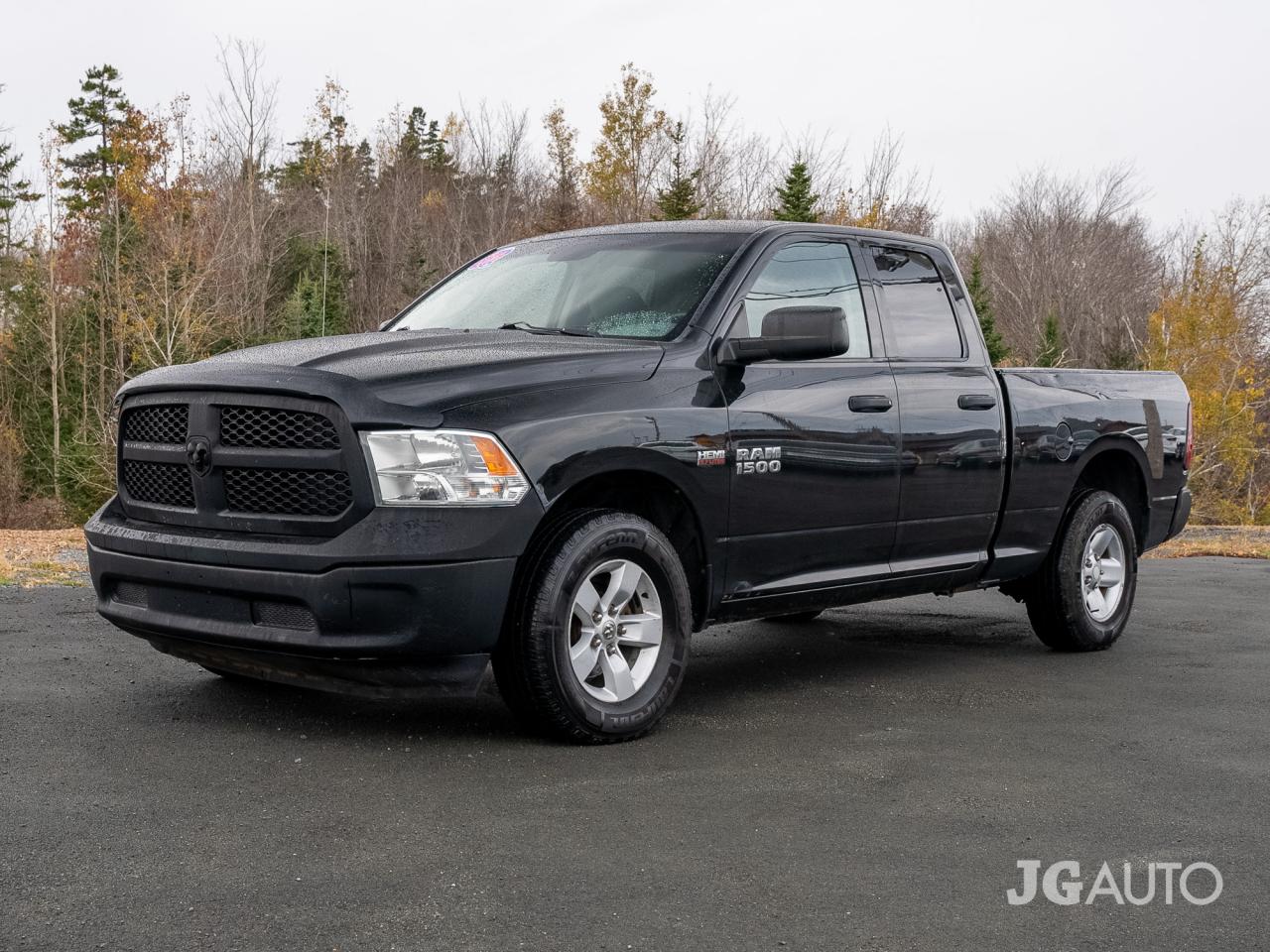 Used 2015 RAM 1500 4WD QUAD CAB 140.5