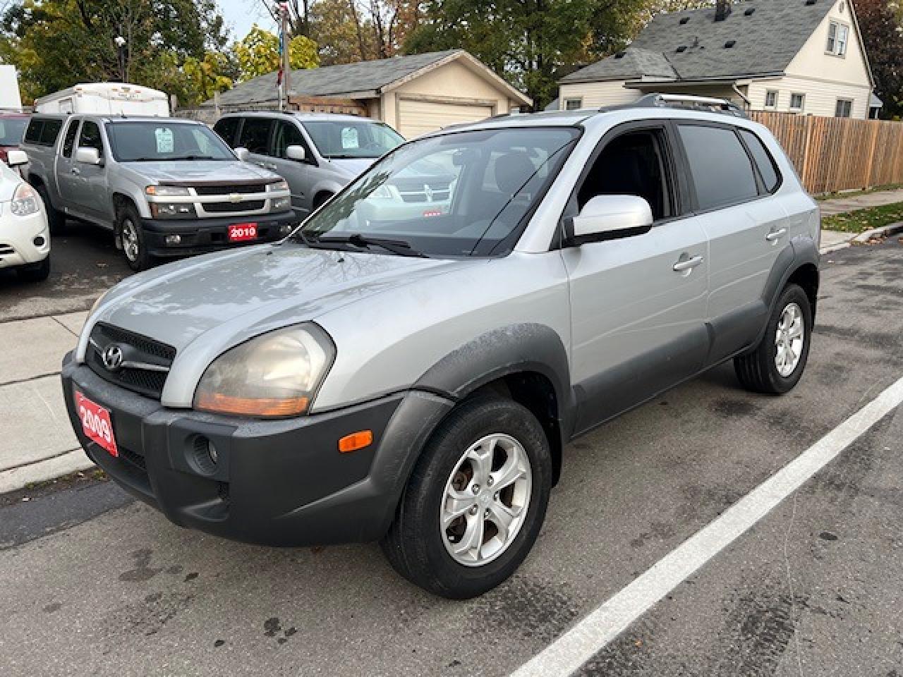 <p>Looking for a reliable and versatile SUV that wont break the bank? Look no further than this 2009 Hyundai Tucson 4WD 4dr V6 Auto from Auto Star Sales Ltd listed at only $6250.00 plus tax and licensing fees! This silver beauty comes equipped with all the features you need for comfortable and safe driving, including a powerful 6-cylinder engine, 4-wheel drive for added traction, and a spacious interior with black cloth seating. With its 181,660km on the odometer, this Tucson has proven its durability and is ready for many more adventures.</p><p>This Tucson is packed with convenient and practical features, making it an ideal choice for families and individuals alike. Enjoy the comfort of heated mirrors, power windows, and a tilt steering wheel for a customized driving experience. Stay safe with features like anti-lock brakes, traction control, and a comprehensive airbag system. The Tucson also includes modern amenities such as cruise control, a CD player, and a security system, ensuring a pleasant and secure ride.</p><p>Here are just a few of the features of this 2009 Hyundai Tucson:</p><ol><li><strong>Powerful 6-cylinder engine:</strong> Experience smooth acceleration and effortless power on the open road.</li><li><strong>4-wheel drive:</strong> Tackle any terrain with confidence, whether its snow, rain, or rough roads.</li><li><strong>Heated mirrors:</strong> Enjoy clear visibility in any weather condition with the convenience of heated mirrors.</li><li><strong>Keyless entry:</strong> Unlock your Tucson with ease using the convenient keyless entry system.</li><li><strong>Security system:</strong> Drive with peace of mind knowing your vehicle is protected with a comprehensive security system.</li></ol><p>Visit Auto Star Sales Ltd today to take this reliable and well-equipped Hyundai Tucson for a test drive.</p>