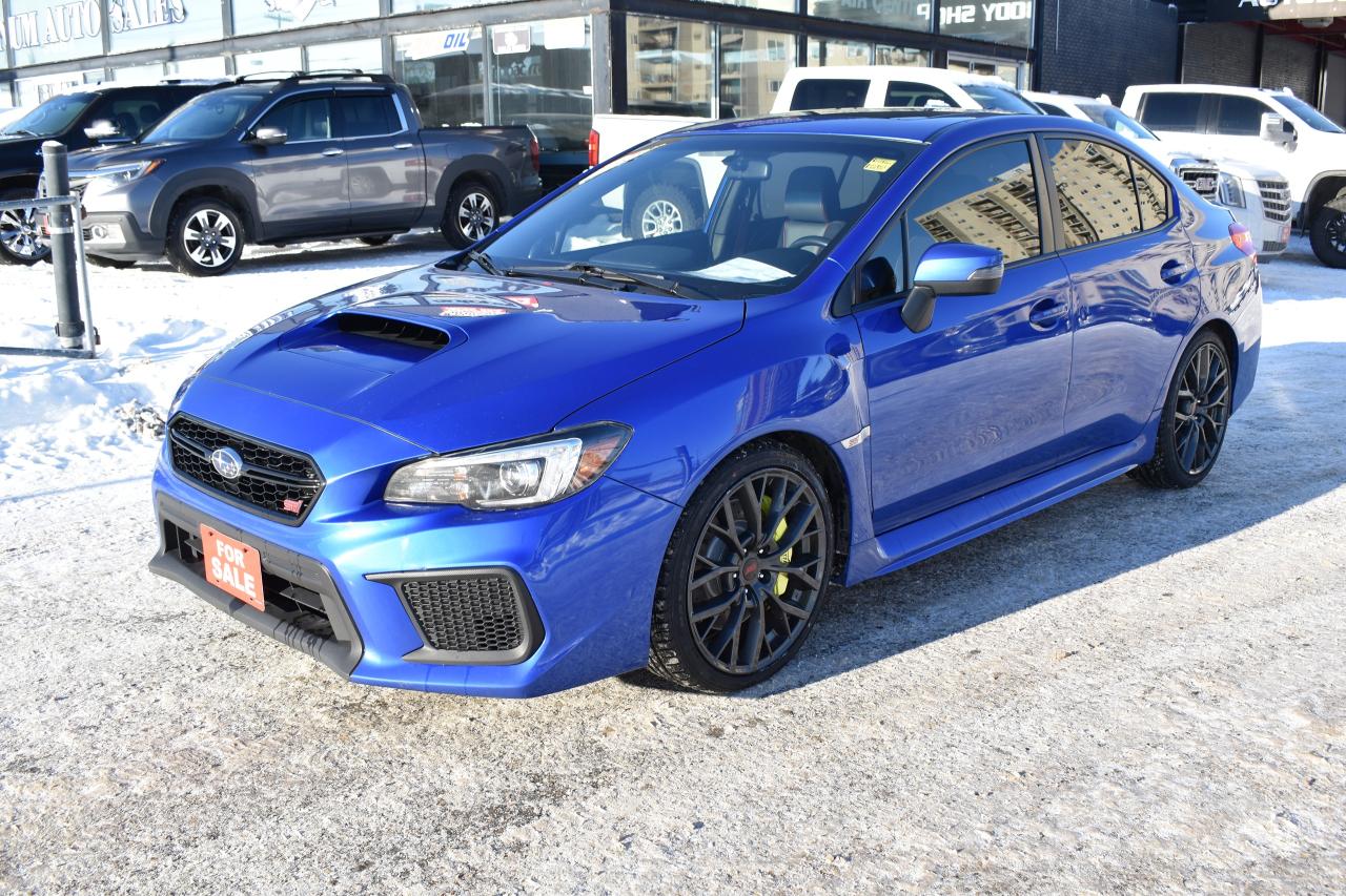 <p>2019 SUBARU WRX STI WITH SPORT TECH PACKAGE </p><p><span style=text-decoration: underline;><strong>LOW KMS </strong></span> ONLY 65,000 KMS!!!</p><p>VERY CLEAN INSIDE AND OUT</p><p>FRESH MANITOBA SAFETY </p><p>CAR IS LOADED UP WITH ALL OPTIONS</p><p>PRICED TO GO AT </p><p>AMAZING CAR IN SUMMER OR WINTER </p><p> </p><p>WE FINANCE </p><p>TAKE TRADES OF ALL SORTS</p><p>OFFER WARRANTY!</p>