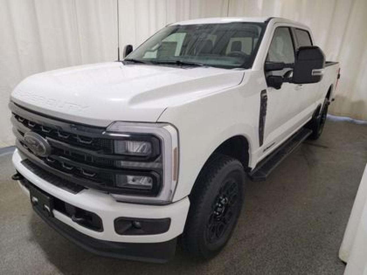 This all new, full sized 2024 Ford F-350 Lariat Crew Cab 4X4 618A looks absolutely stunning in Star White. This heavy duty picks up comes with the 6.7L Power Stroke Diesel engine. This remarkable engine not only produces 475 horsepower and 1,050 ft pounds of torque, but by leveraging technology and a 10-speed automatic transmission. This truck can tow up to a massive amount of 20,000 pounds!

Key Features:
Black Appearance Package
LT275/65R20E BSW All-Terrain
Wheel Well Liners Rear
Hi Gloss Black Aluminum Wheels
FX4 Off Road Package
Twin Panel Moonroof
5th Wheel Hitch Prep Package
Tailgate Step
Leather Trim 40/Console/40 Seat
LED Box Lighting 
8-Way Power Adjustable Seats 
Heated Leather Seats 
Heated Leather Wrapped Steering Wheel 
Universal Garage Door Opener 
360 Degree Camera Package 
Rain Sensing Windshield Wipers 
Reverse Sensing System
B&O Sound System 
Remote Start System 
12 LCD Touchscreen 
Wireless Charging Pad 
Universal Garage Door Opener

This 2024 F-350 Lariat is a built Ford tough truck that leverages physical features and technology that helps you get the job done and enjoy doing it! This specific unit is loaded right up and includes power windows, power locks, air conditioning, 8-way power drivers seat, wrapped steering wheel, zone lighting, cruise, dynamic brake support, outside temperature display, hill start assist, perimeter safety system, four-wheel drive, and so much more. 

Bennett Dunlop Ford has been located at 770 Broad St, in the heart of Regina for over 40 years! Our 4.6 Star google review (Well over 1,800 reviews) is the result of our commitment to providing the fastest, easiest and most fun customer experience possible. Our customers tell us that they love that we dont charge any admin or documentation fees, our sales team will simply offer our best price upfront and we have a no-questions-asked money back guarantee just in case you change your mind after your purchase.