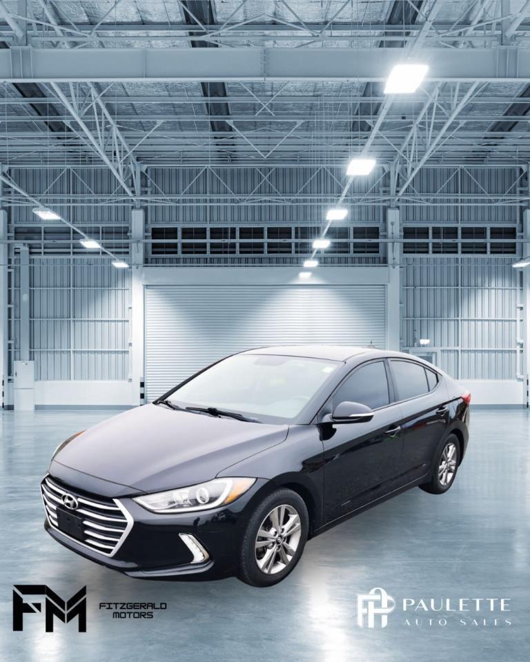 <p>This sleek 2018 Hyundai Elantra GL SE Auto is a fantastic option for anyone looking for a reliable and comfortable sedan. With its stylish black exterior and spacious interior, its sure to turn heads wherever you go. This Elantra is powered by a responsive 4-cylinder engine, paired with a smooth automatic transmission and front-wheel drive, making it a joy to drive.</p><p>Inside, youll find a comfortable and well-equipped cabin. Features include heated front seats, a leather-wrapped steering wheel, a backup camera, and a comprehensive suite of safety features such as stability control, anti-lock brakes, and multiple airbags. With its 176,802 km on the odometer, this Hyundai Elantra is ready to be your daily driver.</p><p>For a closer look at this beautiful Hyundai Elantra GL SE Auto, visit Stephen Fitzgerald Motors today. Our friendly team will be happy to answer any questions you may have and help you take this car for a test drive.</p><p>Here are 5 features that are sure to impress:</p><ul><li><strong>Heated front seats:</strong> Stay warm and cozy on chilly mornings with the heated front seats.</li><li><strong>Leather-wrapped steering wheel:</strong> Experience a luxurious feel with the premium leather-wrapped steering wheel.</li><li><strong>Backup camera:</strong> Drive with confidence and peace of mind with the assistance of a rear-view camera.</li><li><strong>Heated mirrors:</strong> Stay safe in inclement weather with heated side mirrors to ensure optimal visibility.</li><li><strong>Blind spot monitor:</strong> This important safety feature will help you avoid accidents by alerting you to vehicles in your blind spot.</li></ul><p> </p>