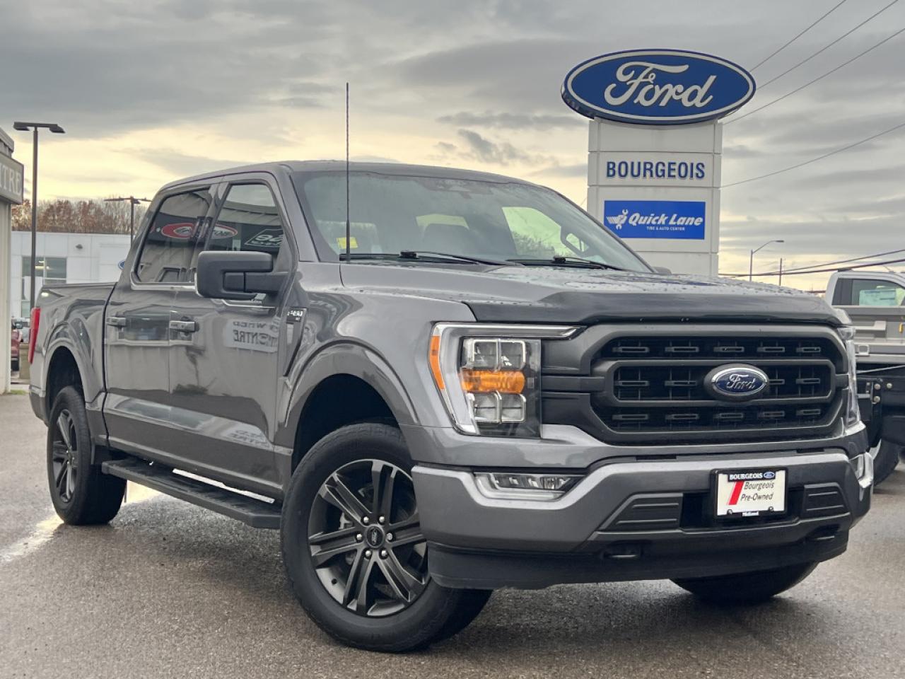 <b>Remote Start,  Apple CarPlay,  Android Auto,  Aluminum Wheels,  Ford Co-Pilot360!</b><br> <br>  Compare at $44285 - Our Price is just $42995! <br> <br>   Smart engineering, impressive tech, and rugged styling make the F-150 hard to pass up. This  2022 Ford F-150 is fresh on our lot in Midland. <br> <br>The perfect truck for work or play, this versatile Ford F-150 gives you the power you need, the features you want, and the style you crave! With high-strength, military-grade aluminum construction, this F-150 cuts the weight without sacrificing toughness. The interior design is first class, with simple to read text, easy to push buttons and plenty of outward visibility. With productivity at the forefront of design, the F-150 makes use of every single component was built to get the job done right!This  Crew Cab 4X4 pickup  has 86,595 kms. Its  carbonized grey metallic in colour  . It has a 10 speed automatic transmission and is powered by a  400HP 5.0L 8 Cylinder Engine.  This unit has some remaining factory warranty for added peace of mind. <br> <br> Our F-150s trim level is XLT. Upgrading to the class leader, this Ford F-150 XLT comes very well equipped with remote keyless entry and remote engine start, dynamic hitch assist, Ford Co-Pilot360 that features lane keep assist, pre-collision assist and automatic emergency braking. Enhanced features include aluminum wheels, chrome exterior accents, SYNC 3 with enhanced voice recognition, Apple CarPlay and Android Auto, FordPass Connect 4G LTE, steering wheel mounted cruise control, a powerful audio system, cargo box lights, power door locks and a rear view camera to help when backing out of a tight spot. This vehicle has been upgraded with the following features: Remote Start,  Apple Carplay,  Android Auto,  Aluminum Wheels,  Ford Co-pilot360,  Dynamic Hitch Assist,  Lane Keep Assist. <br> To view the original window sticker for this vehicle view this <a href=http://www.windowsticker.forddirect.com/windowsticker.pdf?vin=1FTFW1E50NFB47300 target=_blank>http://www.windowsticker.forddirect.com/windowsticker.pdf?vin=1FTFW1E50NFB47300</a>. <br/><br> <br>To apply right now for financing use this link : <a href=https://www.bourgeoismotors.com/credit-application/ target=_blank>https://www.bourgeoismotors.com/credit-application/</a><br><br> <br/><br>At Bourgeois Motors Ford in Midland, Ontario, we proudly present the regions most expansive selection of used vehicles, ensuring youll find the perfect ride in our shared inventory. With a network of dealers serving Midland and Parry Sound, your ideal vehicle is within reach. Experience a stress-free shopping journey with our family-owned and operated dealership, where your needs come first. For over 78 years, weve been committed to serving Midland, Parry Sound, and nearby communities, building trust and providing reliable, quality vehicles. Discover unmatched value, exceptional service, and a legacy of excellence at Bourgeois Motors Fordwhere your satisfaction is our priority.Please note that our inventory is shared between our locations. To avoid disappointment and to ensure that were ready for your arrival, please contact us to ensure your vehicle of interest is waiting for you at your preferred location. <br> Come by and check out our fleet of 70+ used cars and trucks and 180+ new cars and trucks for sale in Midland.  o~o