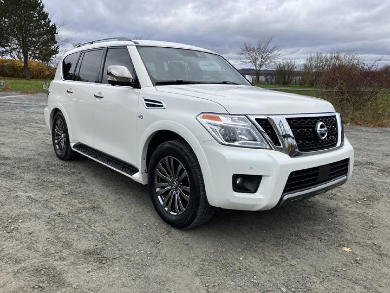 The 2019 Nissan Armada Platinum is a standout full-size SUV that combines luxury, power, and practicality in a way that few can match. From the moment you step inside, the quality of the materials and the attention to detail are immediately apparent. The leather upholstery, wood accents, and premium finishes elevate the interior, while the spacious cabin ensures comfort for up to eight passengers.Performance-wise, the Armada shines with its 5.6-liter V8 engine, delivering 390 horsepower and 394 lb-ft of torque. Whether youre cruising on the highway or towing heavy loads (up to 8,500 lbs), the Armada provides smooth and powerful acceleration, making it a fantastic option for road trips and hauling large trailers.One of the standout features of the 2019 Armada Platinum is its extensive list of tech and safety features. The 12.3-inch touchscreen, Apple CarPlay, and Android Auto make connectivity seamless, while the 360-degree camera system, adaptive cruise control, blind-spot monitoring, and forward-collision warning offer peace of mind when on the road.Ride quality is also excellent. The Armada absorbs bumps and rough roads with ease, providing a smooth, comfortable experience for both driver and passengers. Whether youre navigating city streets or venturing off-road, the Armada feels composed and confident.With its impressive towing capacity, luxurious interior, and a host of advanced features, the 2019 Nissan Armada Platinum is a top choice for families looking for a full-size SUV that doesnt compromise on style, comfort, or capability. Its an excellent blend of performance and refinement.