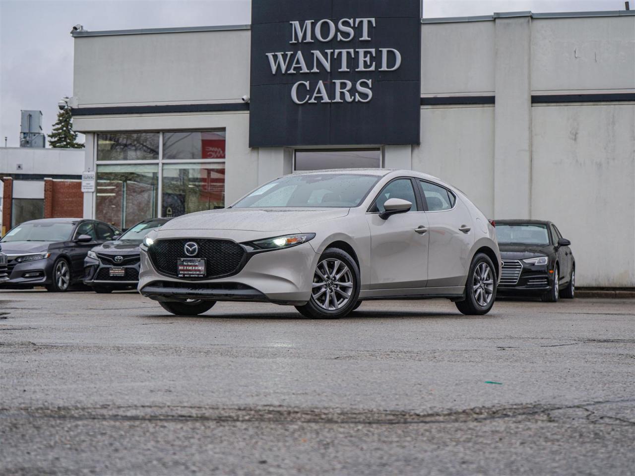 <div style=text-align: justify;><span style=font-size:14px;><span style=font-family:times new roman,times,serif;>This 2022 Mazda Mazda3 has a CLEAN CARFAX with no accidents and is also a Canadian vehicle with service records. High-value options included with this vehicle are; blind spot indicators, lane departure warning, adaptive cruise control, pre-collision, heated steering wheel, push button, app connect, back up camera, touchscreen, heated seats and 16” alloy rims, offering immense value.<br /><br />Why buy from us?<br /> <br />Most Wanted Cars is a place where customers send their family and friends. MWC offers the best financing options in Kitchener-Waterloo and the surrounding areas. Family-owned and operated, MWC has served customers since 1975 and is also DealerRater’s 2022 Provincial Winner for Used Car Dealers. MWC is also honoured to have an A+ standing on Better Business Bureau and a 4.8/5 customer satisfaction rating across all online platforms with over 1400 reviews. With two locations to serve you better, our inventory consists of over 150 used cars, trucks, vans, and SUVs.<br /> <br />Our main office is located at 1620 King Street East, Kitchener, Ontario. Please call us at 519-772-3040 or visit our website at www.mostwantedcars.ca to check out our full inventory list and complete an easy online finance application to get exclusive online preferred rates.<br /> <br />*Price listed is available to finance purchases only on approved credit. The price of the vehicle may differ from other forms of payment. Taxes and licensing are excluded from the price shown above*</span></span></div><br />