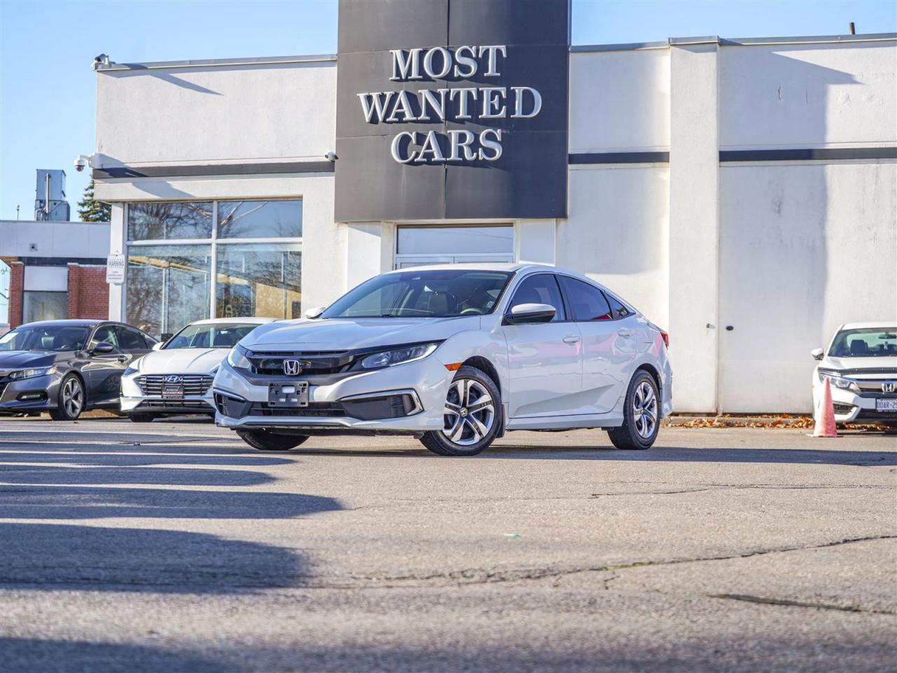 <div style=text-align: justify;><span style=font-size:14px;><span style=font-family:times new roman,times,serif;>This 2020 Honda Civic has a CLEAN CARFAX with no accidents and is also a Canadian vehicle with Roadsport Honda service records. High-value options included with this vehicle are; lane departure warning, adaptive cruise control, pre-collision, app connect, back up camera, touchscreen and heated seats, offering immense value.</span></span><br /><br /><span style=font-size:14px;><span style=font-family:times new roman,times,serif;>Why buy from us?<br /> <br />Most Wanted Cars is a place where customers send their family and friends. MWC offers the best financing options in Kitchener-Waterloo and the surrounding areas. Family-owned and operated, MWC has served customers since 1975 and is also DealerRater’s 2022 Provincial Winner for Used Car Dealers. MWC is also honoured to have an A+ standing on Better Business Bureau and a 4.8/5 customer satisfaction rating across all online platforms with over 1400 reviews. With two locations to serve you better, our inventory consists of over 150 used cars, trucks, vans, and SUVs.<br /> <br />Our main office is located at 1620 King Street East, Kitchener, Ontario. Please call us at 519-772-3040 or visit our website at www.mostwantedcars.ca to check out our full inventory list and complete an easy online finance application to get exclusive online preferred rates.<br /> <br />*Price listed is available to finance purchases only on approved credit. The price of the vehicle may differ from other forms of payment. Taxes and licensing are excluded from the price shown above*</span></span></div><br />