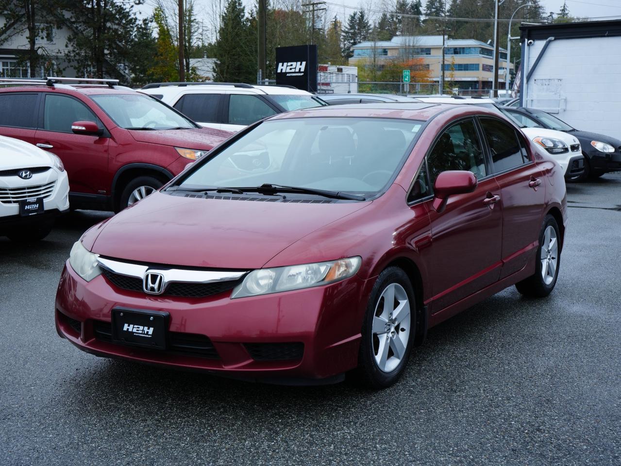 <p>Looking for a reliable and affordable sedan? Look no further than this 2009 Honda Civic 4dr Auto, available now at H2H Auto Group! This maroon beauty is perfect for navigating city streets and long highway drives, boasting a fuel-efficient 4-cylinder engine and smooth automatic transmission. With 162,259km on the odometer, this Civic has plenty of life left in it.</p><p>This Civic is packed with features designed to make your drives comfortable and safe. Enjoy the cool air of the air conditioning on hot days, and feel secure with the anti-lock brakes and multiple airbags. Cruise control makes long trips a breeze, while heated mirrors keep your visibility clear in winter. This Civic is ready to be your next trusty companion, offering a combination of reliability, affordability, and practicality that is sure to impress.</p><p><strong>Here are five key features that make this 2009 Honda Civic stand out:</strong></p><ul><li><strong>Fuel-efficient 4-cylinder engine:</strong> Enjoy the benefits of a powerful and efficient engine that will save you money at the pump.</li><li><strong>Smooth automatic transmission:</strong> Experience effortless shifting and a comfortable ride.</li><li><strong>Anti-lock brakes:</strong> Drive with confidence knowing you have an extra layer of safety.</li><li><strong>Heated mirrors:</strong> Keep your vision clear in all weather conditions.</li><li><strong>Keyless entry:</strong> Enjoy the convenience of easily unlocking and starting your car without needing your keys.</li></ul><p>Dont miss your chance to own this reliable and affordable Civic! Contact H2H Auto Group today for more information.</p><p><em>Powered by AutoIntelligence™ AI</em></p>