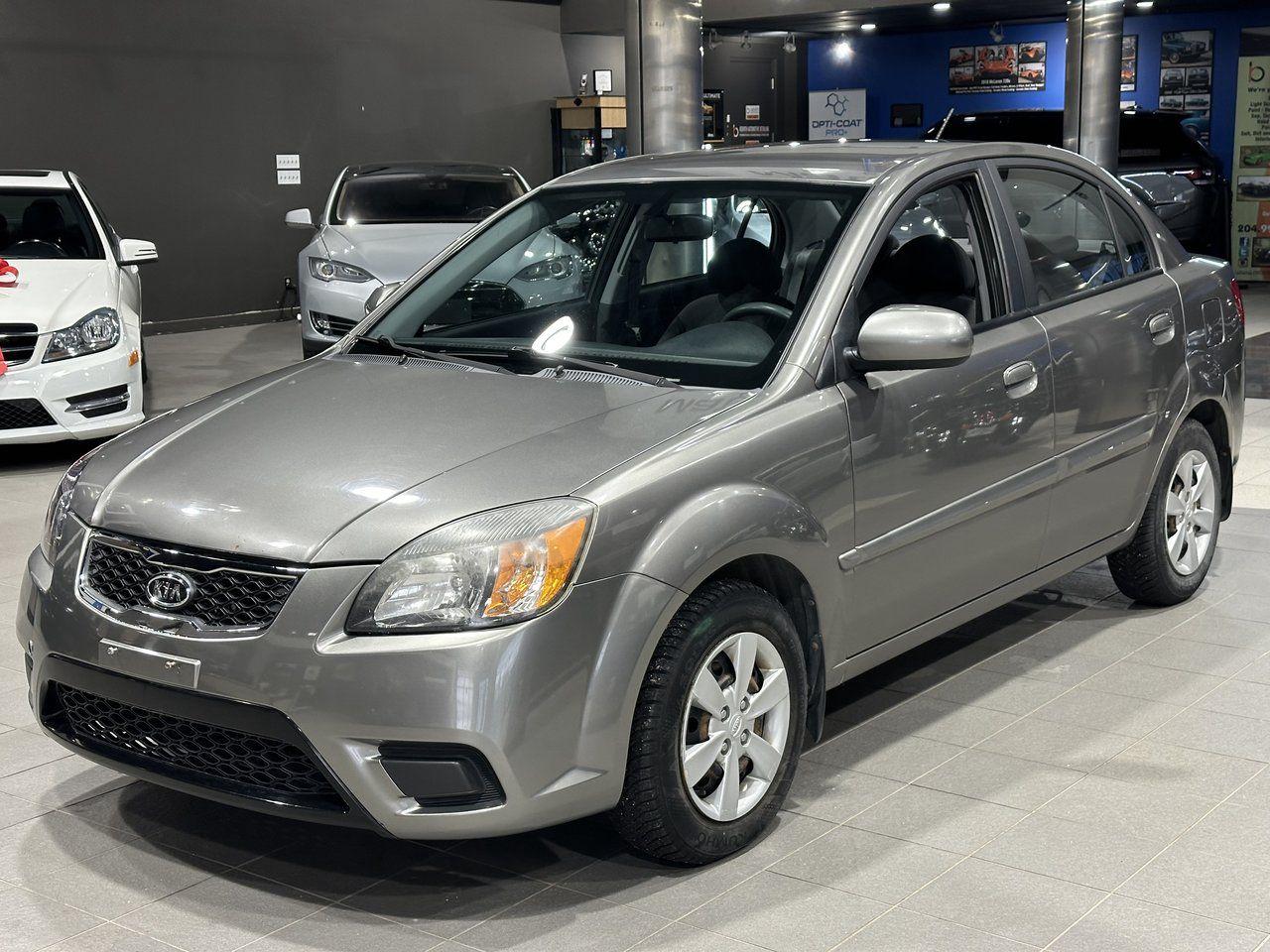 <p><strong>High Value Options:</strong></p><ul><li>Low Mileage</li><li>Cruise Control</li><li>Clean Title</li><li>Heated Seats</li></ul><p>The 2011 Kia Rio is a compact and efficient vehicle, ideal for city driving and daily commutes. This model has low mileage, making it a great choice for those looking for a well-maintained car with plenty of life left. Equipped with cruise control, it offers added convenience on longer drives. The clean title ensures peace of mind for its next owner, and the heated seats provide extra comfort during colder months. Known for its fuel efficiency and reliability, the Kia Rio is a practical and budget-friendly option.</p><p><strong>3 Month/5000 KM Powertrain Warranty on every vehicle!</strong> 3-month warranty price is included in the advertised price. Extended warranties available (extended warranty prices not included).</p><p>Every vehicle sold at Match is clean title. We do not sell ANY rebuilt vehicles. We also provide a verified CarFax report for each vehicle.</p><p>Financing available; please visit <a target=_blank rel=noopener noreferrer href=http://www.matchautomarket.ca><a rel=noopener target=_new><span>www.matchautomarket.ca</span></a></a>.</p><p>Dealer permit: 4858<br>Address: 231 Oak Point Hwy</p>