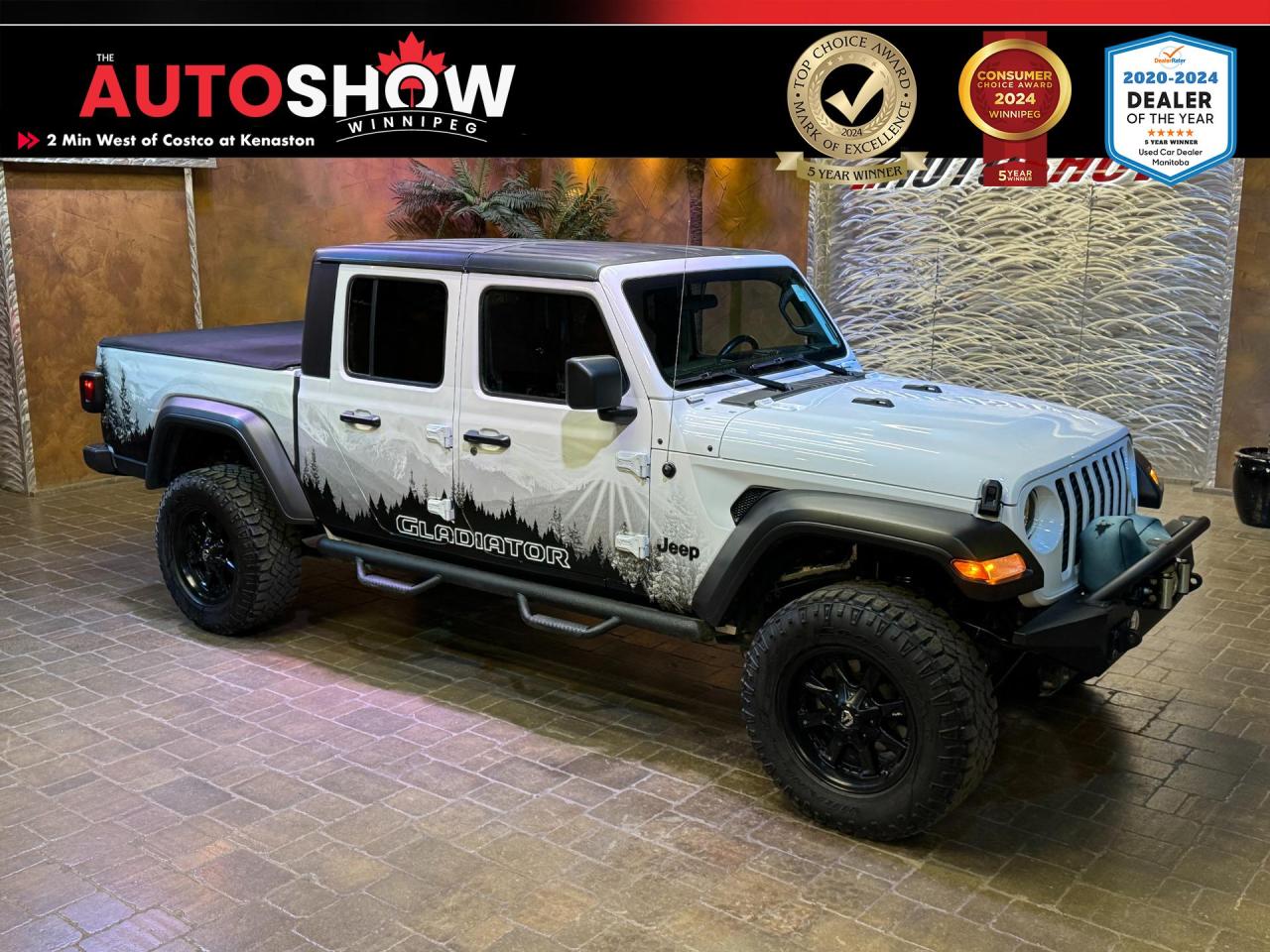 The 2020 Jeep Gladiator Sport S is a versatile and capable vehicle that excels both on and off the road. Its combination of rugged design, powerful performance, and modern technology makes it an excellent choice for those who seek adventure without compromising on comfort and practicality. Whether youre navigating city streets or exploring off-the-beaten-path trails, the Gladiator Sport S is ready to take on the challenge. With its impressive towing and payload capacities, its not just an off-road enthusiasts dream but also a reliable partner for work and play. The blend of Jeeps iconic styling and modern amenities ensures that youre not only driving a truck but also making a statement. The Gladiator Sport S stands out in its class, offering a unique blend of utility, performance, and style that few can match.<br /><br /><strong>FEATURES OF THE 2020 JEEP GLADIATOR SPORT S</strong><br /><br /><strong>CONVENIENCE</strong><ul> <li>Remote Engine Start</li> <li>Dual-Climate Control</li> <li>Cruise Control</li></ul><br /><strong>SAFETY FEATURES</strong><ul> <li>Rear View Camera</li> <li>Hill Start Assist</li> <li>Electronic Roll Mitigation</li> <li>Tire Pressure Monitoring System</li> <li>Trailer Sway Control</li> <li>Traction Control</li> <li>Stability Control</li></ul><br /><strong>TECHNOLOGY</strong><ul> <li>7-Inch Touch-Screen</li> <li>Apple CarPlay</li> <li>Android Auto</li> <li>SiriusXM</li> <li>Bluetooth</li> <li>AM/FM Stereo</li> <li>USB Ports</li> <li>8-Speaker</li></ul><br /><strong>PERFORMANCE</strong><ul> <li>3.6L V6 Engine</li> <li>Automatic Transmission </li></ul><br /><br />Will accept trades. Please call (204)560-6287 or View at 3165 McGillivray Blvd. (Conveniently located two minutes West from Costco at corner of Kenaston and McGillivray Blvd.)<br /><br />In addition to this used 2020 JEEP GLADIATOR please view our complete inventory of used <a href=\https://www.autoshowwinnipeg.com/used-trucks-winnipeg/\>trucks</a>, used <a href=\https://www.autoshowwinnipeg.com/used-cars-winnipeg/\>SUVs</a>, used <a href=\https://www.autoshowwinnipeg.com/used-cars-winnipeg/\>Vans</a>, used <a href=\https://www.autoshowwinnipeg.com/new-used-rvs-winnipeg/\>RVs</a>, and used <a href=\https://www.autoshowwinnipeg.com/used-cars-winnipeg/\>Cars</a> in Winnipeg on our website: <a href=\https://www.autoshowwinnipeg.com/\>WWW.AUTOSHOWWINNIPEG.COM</a><br /><br />Complete comprehensive warranty is available for this vehicle. Please ask for warranty option details. All advertised prices, fees and payments plus taxes (where applicable).<br /><br />Winnipeg, MB - Manitoba Dealer Permit # 5851