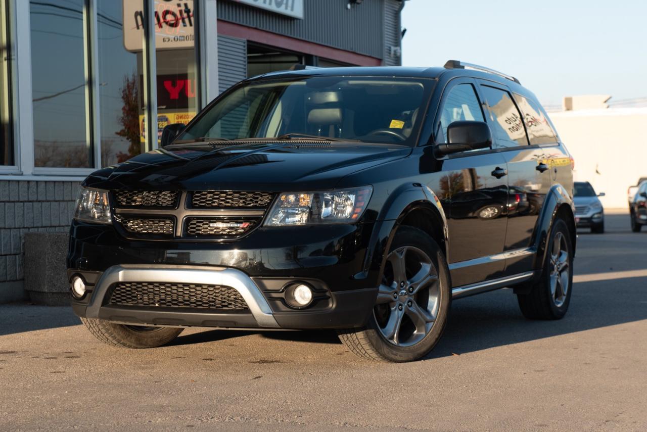 <p>Get out on the road in our 2016 Dodge Journey Crossroad sculpted in radiant Pitch Black Clear Coat! Powered by our award-winning 3.6 Litre V6 that generates a healthy 283hp on command while connected to a 6 Speed Automatic transmission for amazing road authority. This Front Wheel Drive helps reward you with approximately 9.8L/100km on the highway! You'll make a powerful impression with our Crossroad, accented by chrome, gloss black fog lamp surrounds, black wheels, sunroof, a black grille, and dark-tinted headlamps. Climb inside this Crossroad and experience the comfort of heated leather-trimmed seats with sport mesh cloth inserts and light slate gray accent stitching. You'll enjoy the convenience of a power driver's seat, heated steering wheel, proximity key with pushbutton start and power-heated and folding side mirrors. The Uconnect touchscreen interface and steering-wheel-mounted audio and cruise controls keep you focused on the task at hand as you and your passengers listen to a great sound system or stay connected with Bluetooth. With cavernous cargo space, feel free to pack everyone up and drive off into the sunset! Dodge is proud of advanced technology designed to help protect all occupants, and our Journey provides peace of mind as well. Life is a Journey, not a destination. So get behind the wheel... Your adventure awaits! Save this Page and Call for Availability. We Know You Will Enjoy Your Test Drive Towards Ownership! Errors and omissions excepted Good Credit, Bad Credit, No Credit - All credit applications are 100% processed! Let us help you get your credit started or rebuilt with our experienced team of professionals. Good credit? Let us source the best rates and loan that suits you. Same day approval! No waiting! Experience the difference at Chatham's award winning Pre-Owned dealership 3 years running! All vehicles are sold certified and e-tested, unless otherwise stated. Helping people get behind the wheel since 1999! If we don't have the vehicle you are looking for, let us find it! All cars serviced through our onsite facility. Servicing all makes and models. We are proud to serve southwestern Ontario with quality vehicles for over 16 years! Can't make it in? No problem! Take advantage of our NO FEE delivery service! Chatham-Kent, Sarnia, London, Windsor, Essex, Leamington, Belle River, LaSalle, Tecumseh, Kitchener, Cambridge, waterloo, Hamilton, Oakville, Toronto and the GTA.</p>