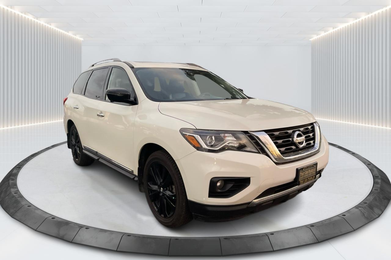 2017 Nissan Pathfinder Platinum 4WD Black Edition - Loaded with DOUBLE DVD  Experience the perfect combination of luxury, capability, and versatility with this 2017 Nissan Pathfinder Platinum 4WD Black Edition. Dressed in an eye-catching black exterior, this SUV exudes a bold and sophisticated presence on the road. Powered by a robust 3.5-liter V6 engine paired with an advanced CVT transmission, the Pathfinder delivers a smooth and powerful performance, making it ideal for both city driving and off-road adventures. The 4WD system ensures you can tackle a variety of terrains with confidence, whether its rain, snow, or rugged trails. Step inside to find a meticulously crafted interior loaded with high-end features. The Platinum trim includes premium leather seating for up to seven passengers, heated and cooled front seats, and a spacious cabin designed for ultimate comfort. The standout feature of this model is the double DVD entertainment system, perfect for keeping passengers entertained on long journeys. The advanced infotainment system boasts a large touchscreen display, navigation, Bluetooth connectivity, and a premium audio system, ensuring that every drive is enjoyable and connected. Safety features are plentiful, including a rearview camera, blind-spot monitoring, forward collision warning, and more, providing peace of mind for every adventure. With its striking design, luxury features, and impressive capability, this 2017 Nissan Pathfinder Platinum 4WD Black Edition is the perfect choice for families or anyone seeking a reliable and stylish SUV. Save time,  money and shopping frustration with our transparent, no-hassle pricing. We use state of the art technology to shop the competition for you and price our pre-owned vehicles to give you the best value, upfront, every time and back it up with a free market value report so you know you are getting the best deal! With no additional fees, theres no surprises either, the price you see is the price you pay, just add HST! We offer 50+ Vehicles on site with financing for our customers regardless of credit. We have a dedicated team of credit rebuilding experts on hand to help you get into the car of your dreams. We need your trade-in! We have a hassle free top dollar trade process and offer a free evaluation on your car. We will buy your vehicle even if you do not buy one from us!  THAT CAR PLACE has been in business for 27 years.  We are OMVIC Certified and and are Members of the UCDA earning your trust so you can buy with confidence.  50+ VEHICLES in ONE LOCATION. USED VEHICLE MARKET PRICING! We use an exclusive 3rd party marketing tool that accurately monitor vehicle prices to guarantee our customers get the best value. We implement Zero-Pressure, Hassle-Free sales process.  No hidden Admin Fees. VEHICLE HISTORY: Free Carfax report included with every purchase. AWARDS include National Dealer of the Year Winner of Outstanding Customer Satisfaction.  Voted #1 Best Used Car Dealership in London, Ont. 2014 to 2024.  Winner of Top Choice Award 6 times between the years 2015 and 2024.  Winner of Londons Readers Choice Award 2014 to 2023.  Accredited Better Business Bureau rating.  Each vehicle includes FULL SAFETY: Full safety inspection exceeding industry standards: all vehicles go through an intensive inspection RECONDITIONING. All brake pads or rotors below 50% material are replaced. Each vehicle sold receives a semi-synthetic oil-lube-filter and full detailing and clean up