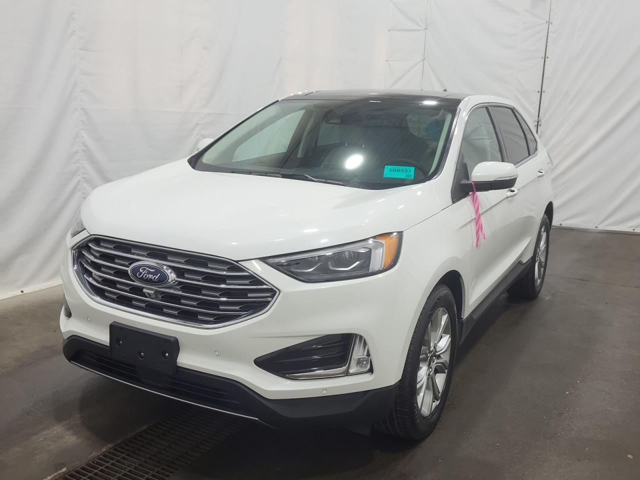 THE PRICE YOU SEE, PLUS GST. GUARANTEED!  PREVIOUS FORD EXECUTIVE DRIVEN VEHICLE!  APPLE CARPLAY/ANDROID AUTO! 2.0 LITER ECOBOOST, 8 SPEED AUTO, TITANIUM PKG(301a), PANORAMIC ROOF, COLD WEATHER PKG, CLASS II TRAILER TOW PKG.     The 2024 Ford Edge Titanium is a midsize SUV that strikes an impressive balance between performance, comfort, and technology, making it an excellent choice for modern families and adventure seekers alike. Under the hood, it features a 2.0-liter EcoBoost engine, which employs turbocharging and direct fuel injection to deliver a spirited 250 horsepower and 275 lb-ft of torque. Paired with an efficient 8-speed automatic transmission, this combination not only contributes to a responsive driving experience but also optimizes fuel economy, making it well-suited for both city driving and long-distance travel. The Edge Titanium stands out with its upscale interior, showcasing premium materials, stylish design elements, and the latest in Fords SYNC infotainment system, which includes features like a large touchscreen display, smartphone integration via Apple CarPlay and Android Auto, and a premium audio system. Safety is also a top priority, with a comprehensive suite of advanced driver-assistance features such as adaptive cruise control, blind-spot monitoring, and lane-keeping assist, enhancing confidence on the road. The spacious cabin provides ample room for passengers and cargo, ensuring that the Edge Titanium is as practical as it is luxurious, catering to a variety of lifestyle needs while delivering a smooth and engaging ride.   Do you want to know more about this vehicle, CALL, CLICK OR COME ON IN!*AMVIC Licensed Dealer; CarFax and Full Mechanical Inspection Included.