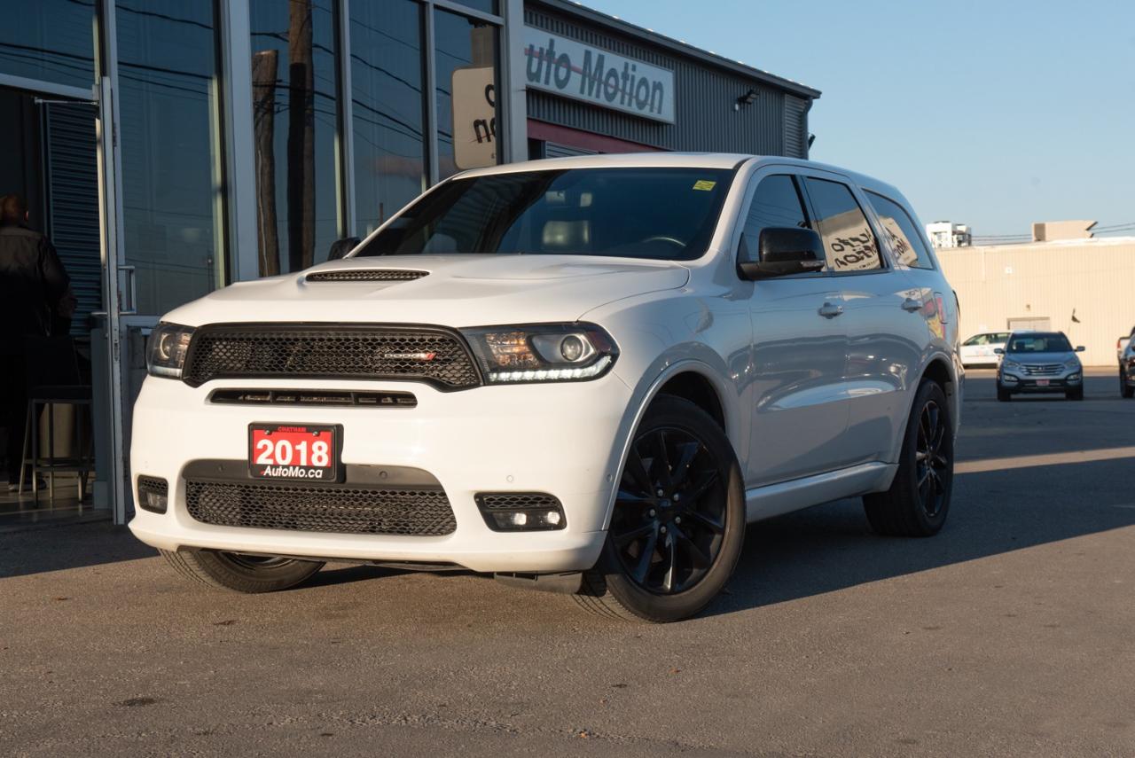 <p>Our impressive 2018 Dodge Durango R/T AWD is stunning in White Knuckle! Powered by a 5.7 Litre HEMI V8 that offers 360hp connected to an 8 Speed Automatic transmission. This All Wheel Drive SUV executes flawlessly with sport-tuned suspension, yielding approximately 10.7L/100km on the road with ample get-up-and-go and responsive handling. You'll make a powerful first impression with the muscular stance of our R/T! R/T offers heated leather front power memory seats and a great road view that adds the touchscreen display. Crank up the Beats audio, open the sunroof, or make a phone call with Bluetooth® while keeping your hands on the heated steering wheel. Comfort and confidence reign supreme with Dodge as it has earned excellent safety scores thanks to ABS, stability/traction control, a rearview camera, parking sensors, and advanced airbags, among other features. Designed with your family's adventures in mind, this Durango R/T is an ideal choice you'll appreciate once you get behind the wheel. Save this Page and Call for Availability. We Know You Will Enjoy Your Test Drive Towards Ownership! Errors and omissions excepted Good Credit, Bad Credit, No Credit - All credit applications are 100% processed! Let us help you get your credit started or rebuilt with our experienced team of professionals. Good credit? Let us source the best rates and loan that suits you. Same day approval! No waiting! Experience the difference at Chatham's award winning Pre-Owned dealership 3 years running! All vehicles are sold certified and e-tested, unless otherwise stated. Helping people get behind the wheel since 1999! If we don't have the vehicle you are looking for, let us find it! All cars serviced through our onsite facility. Servicing all makes and models. We are proud to serve southwestern Ontario with quality vehicles for over 16 years! Can't make it in? No problem! Take advantage of our NO FEE delivery service! Chatham-Kent, Sarnia, London, Windsor, Essex, Leamington, Belle River, LaSalle, Tecumseh, Kitchener, Cambridge, waterloo, Hamilton, Oakville, Toronto and the GTA.</p>