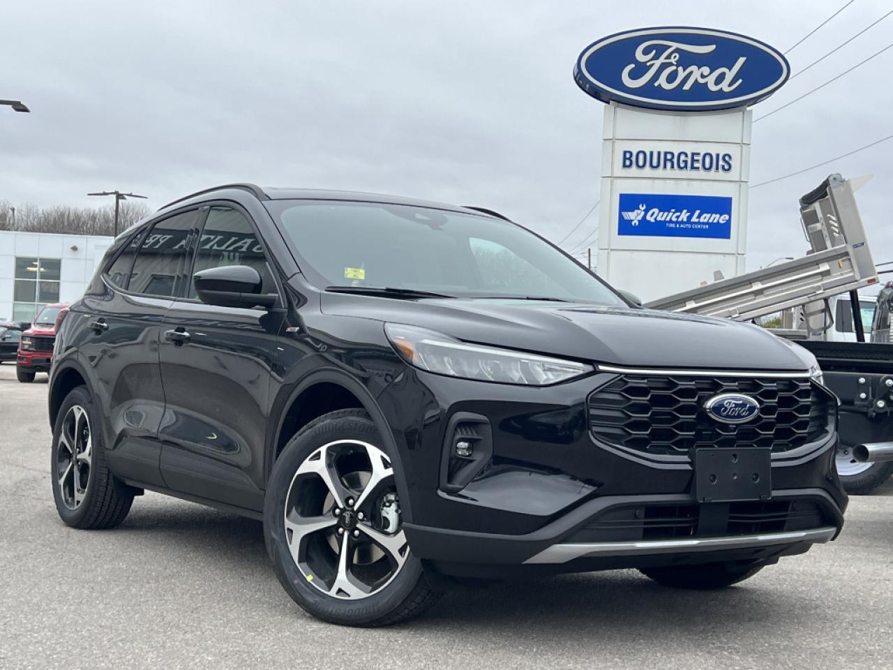 <b>Sunroof, Wireless Charging, Heated Seats, 19 inch Aluminum Wheels, Tech Package!</b><br> <br> <br> <br>  Greetings. <br> <br><br> <br> This agate black SUV  has a cvt transmission and is powered by a  192HP 2.5L 4 Cylinder Engine.<br> <br> Our Escapes trim level is ST-Line Select. This ST-Line Select AWD features heated front seats and remote engine start, as well as aluminum wheels, body colored exterior styling and ActiveX synthetic leather seating upholstery, and amazing standard features such as a power-operated liftgate for rear cargo access, LED headlights with automatic high beams, an 8-inch infotainment screen powered by SYNC 4 with wireless Apple CarPlay and Android Auto, FordPass Connect with 4G mobile internet hotspot access, and proximity keyless entry with push button start. Road safety features include blind spot detection, pre-collision assist with automatic emergency braking and a back-up camera, lane keeping assist, lane departure warning, and front and rear collision mitigation. Additional features include dual-zone climate control, front and rear cupholders, smart device remote engine start, and even more. This vehicle has been upgraded with the following features: Sunroof, Wireless Charging, Heated Seats, 19 Inch Aluminum Wheels, Tech Package, Lane Assist, 360 Camera. <br><br> View the original window sticker for this vehicle with this url <b><a href=http://www.windowsticker.forddirect.com/windowsticker.pdf?vin=1FMCU9NZ4SUA13502 target=_blank>http://www.windowsticker.forddirect.com/windowsticker.pdf?vin=1FMCU9NZ4SUA13502</a></b>.<br> <br>To apply right now for financing use this link : <a href=https://www.bourgeoismotors.com/credit-application/ target=_blank>https://www.bourgeoismotors.com/credit-application/</a><br><br> <br/> 6.99% financing for 84 months.  Incentives expire 2024-12-02.  See dealer for details. <br> <br>Discount on vehicle represents the Cash Purchase discount applicable and is inclusive of all non-stackable and stackable cash purchase discounts from Ford of Canada and Bourgeois Motors Ford and is offered in lieu of sub-vented lease or finance rates. To get details on current discounts applicable to this and other vehicles in our inventory for Lease and Finance customer, see a member of our team. </br></br>Discover a pressure-free buying experience at Bourgeois Motors Ford in Midland, Ontario, where integrity and family values drive our 78-year legacy. As a trusted, family-owned and operated dealership, we prioritize your comfort and satisfaction above all else. Our no pressure showroom is lead by a team who is passionate about understanding your needs and preferences. Located on the shores of Georgian Bay, our dealership offers more than just vehiclesits an experience rooted in community, trust and transparency. Trust us to provide personalized service, a diverse range of quality new Ford vehicles, and a seamless journey to finding your perfect car. Join our family at Bourgeois Motors Ford and let us redefine the way you shop for your next vehicle.<br> Come by and check out our fleet of 70+ used cars and trucks and 190+ new cars and trucks for sale in Midland.  o~o