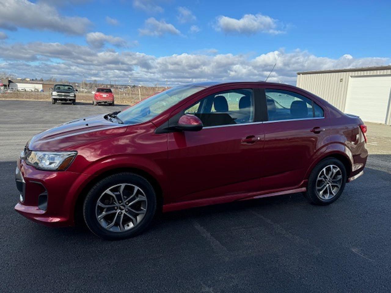 <p>Looking for a reliable and stylish compact car thats packed with features? Look no further than this 2017 Chevrolet Sonic 4dr Sdn Auto LT, available now at Canadian Auto Sales NL. This red hatchback boasts a sleek design and a comfortable grey/red interior, making it perfect for both city driving and weekend adventures. With just 67,527km on the odometer, this Sonic is ready to take you wherever you need to go.</p><p>This Sonic comes equipped with a range of features that will make every drive a pleasure. Enjoy the convenience of keyless entry and remote start, keeping you warm and comfortable even on the coldest days. Stay connected with the built-in WiFi Hotspot, allowing you to seamlessly access the internet while on the go. Safety is paramount, and this Sonic doesnt disappoint with features like a back-up camera, anti-lock brakes, and multiple airbags to keep you protected on the road. And for those chilly mornings, the heated front seats and heated mirrors will keep you warm and cozy.</p><p>This 2017 Chevrolet Sonic 4dr Sdn Auto LT is a fantastic option for anyone seeking a dependable and well-equipped compact car. Visit Canadian Auto Sales NL today to take it for a test drive and experience the Sonics smooth ride and impressive features for yourself!</p><p><em>Powered by AutoIntelligence™ AI</em></p>