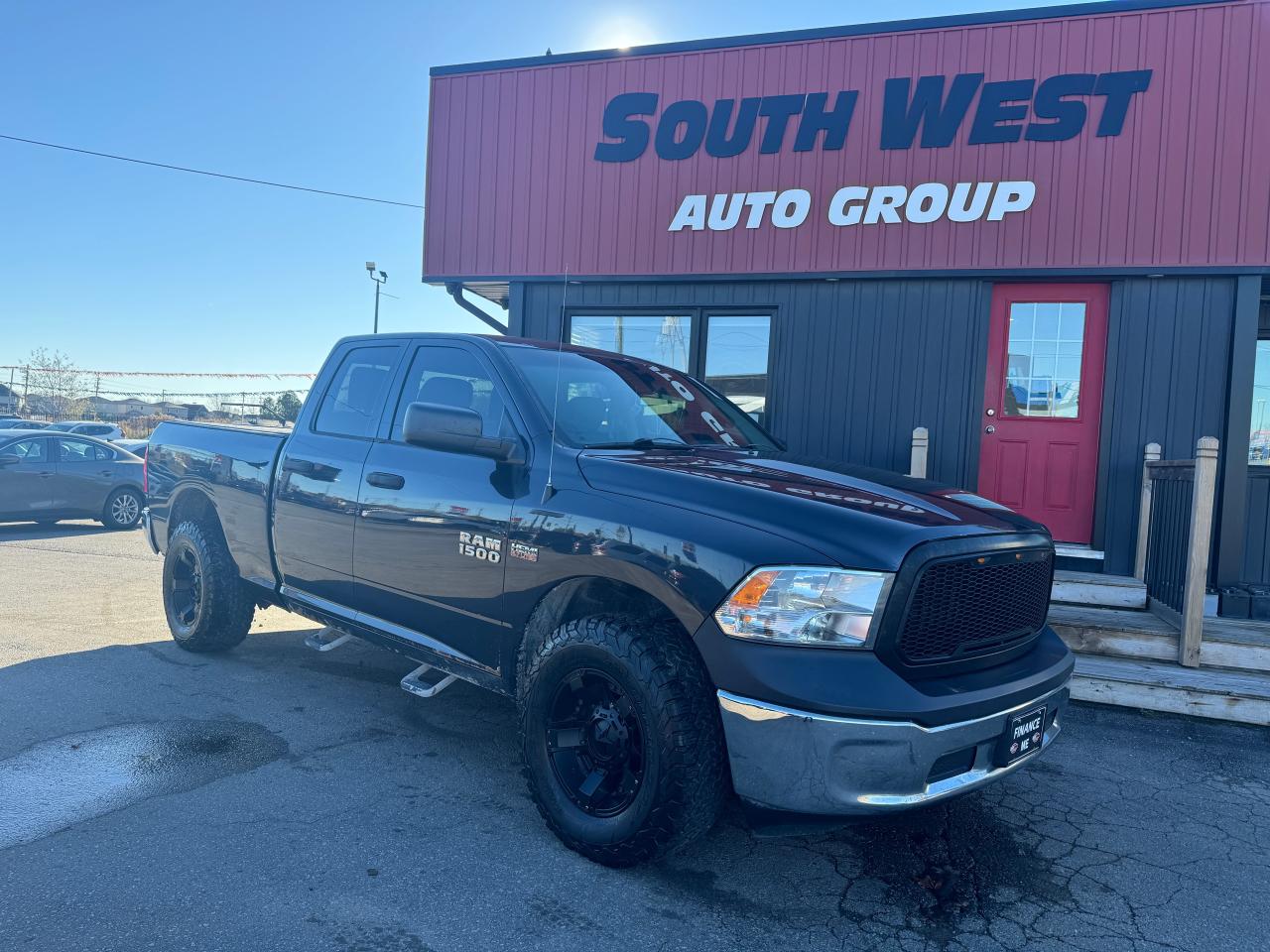 Used 2014 RAM 1500 4WD QUAD CAB 140.5