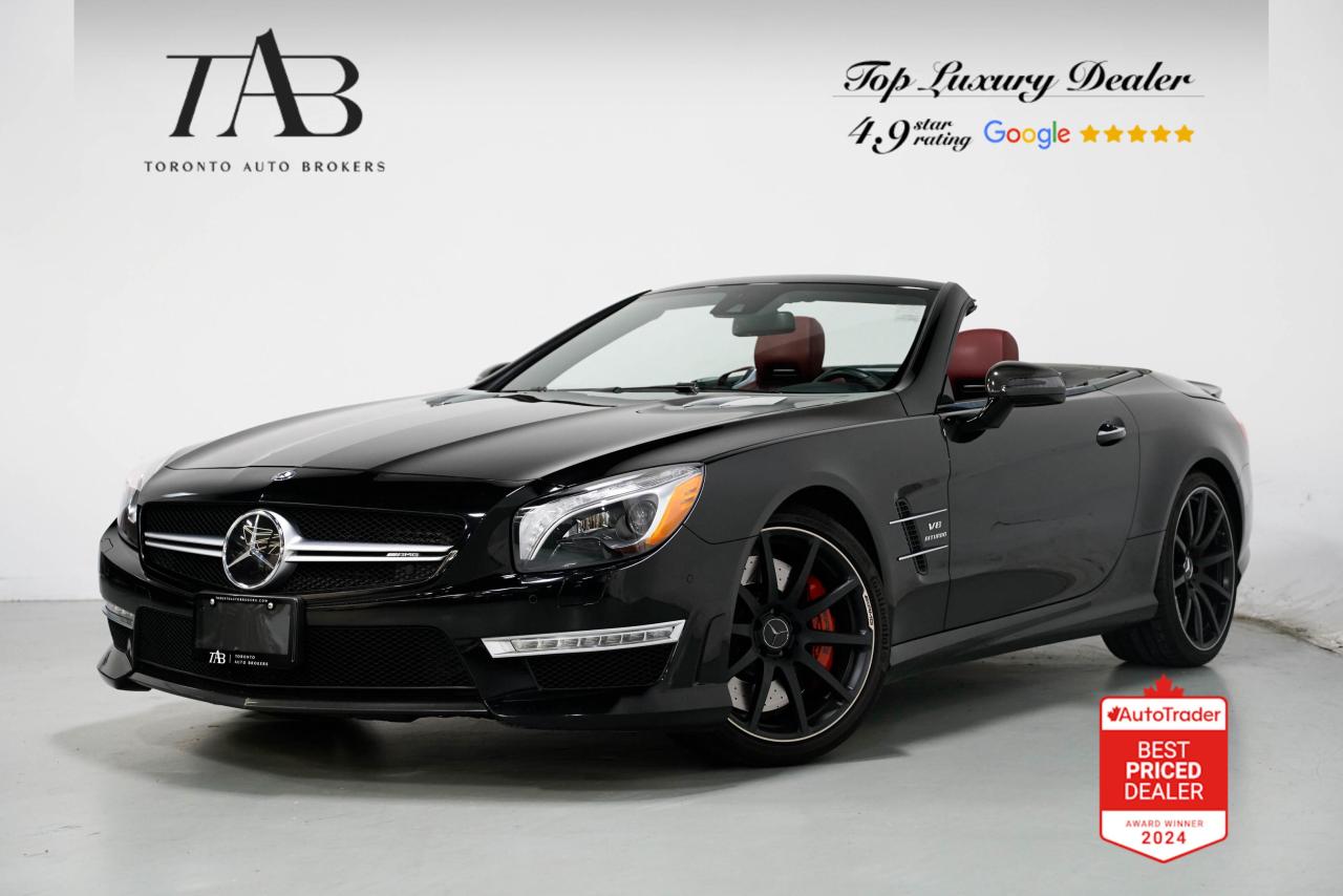 This 2015 Mercedes-Benz SL 63 AMG is a Local Ontario Vehicle with Clean Carfax Report. It is a high-performance luxury roadster that combines exhilarating speed with timeless elegance. Its handcrafted AMG engine, sporty design, and exclusive red interior make it a true icon of open-top driving.

Key Features:

5.5L Handcrafted AMG Bi-turbo V8 Engine 
AMG SPEEDSHIFT MCT 7-Speed Transmission
Rear-Wheel Drive with AMG Performance Suspension
Performance Package with Enhanced Dynamics 
Exclusive Red Leather Interior
Retractable Hardtop with MAGIC SKY CONTROL
AMG Alloy Wheels
AMG High-Performance Braking System
Premium Harman Kardon Logic 7 Surround Sound System
COMAND Infotainment System with Navigation
Heated and Ventilated AMG Sport Seats
Adaptive Highbeam Assist with Bi-Xenon Headlights
Advanced Safety Features
Carbon Fiber Trim Accents

NOW OFFERING 3 MONTH DEFERRED FINANCING PAYMENTS ON APPROVED CREDIT.

 Looking for a top-rated pre-owned luxury car dealership in the GTA? Look no further than Toronto Auto Brokers (TAB)! Were proud to have won multiple awards, including the 2024 AutoTrader Best Priced Dealer, 2024 CBRB Dealer Award, the Canadian Choice Award 2024, the 2024 BNS Award, the 2024 Three Best Rated Dealer Award, and many more!

With 30 years of experience serving the Greater Toronto Area, TAB is a respected and trusted name in the pre-owned luxury car industry. Our 30,000 sq.Ft indoor showroom is home to a wide range of luxury vehicles from top brands like BMW, Mercedes-Benz, Audi, Porsche, Land Rover, Jaguar, Aston Martin, Bentley, Maserati, and more. 

At TAB, were committed to providing a no-pressure environment and honest work ethics. As a family-owned and operated business, we treat every customer like family and ensure that every interaction is a positive one. Come experience the TAB Lifestyle at its truest form, luxury car buying has never been more enjoyable and exciting!

We offer a variety of services to make your purchase experience as easy and stress-free as possible. From competitive and simple financing and leasing options to extended warranties, aftermarket services, and full history reports on every vehicle, we have everything you need to make an informed decision. We welcome every trade, even if youre just looking to sell your car without buying, and when it comes to financing or leasing, we offer same day approvals, with access to over 50 lenders, including all of the banks in Canada. Feel free to check out your own Equifax credit score without affecting your credit score, simply click on the Equifax tab above and see if you qualify.

So if youre looking for a luxury pre-owned car dealership in Toronto, look no further than TAB! We proudly serve the GTA, including Toronto, Etobicoke, Woodbridge, North York, York Region, Vaughan, Thornhill, Richmond Hill, Mississauga, Scarborough, Markham, Oshawa, Peteborough, Hamilton, Newmarket, Orangeville, Aurora, Brantford, Barrie, Kitchener, Niagara Falls, Oakville, Cambridge, Kitchener, Waterloo, Guelph, London, Windsor, Orillia, Pickering, Ajax, Whitby, Durham, Cobourg, Belleville, Kingston, Ottawa, Montreal, Vancouver, Winnipeg, Calgary, Edmonton, Regina, Halifax, and more.

Call us today or visit our website to learn more about our inventory and services. And remember, all prices exclude applicable taxes and licensing, and vehicles can be certified at an additional cost of $799.