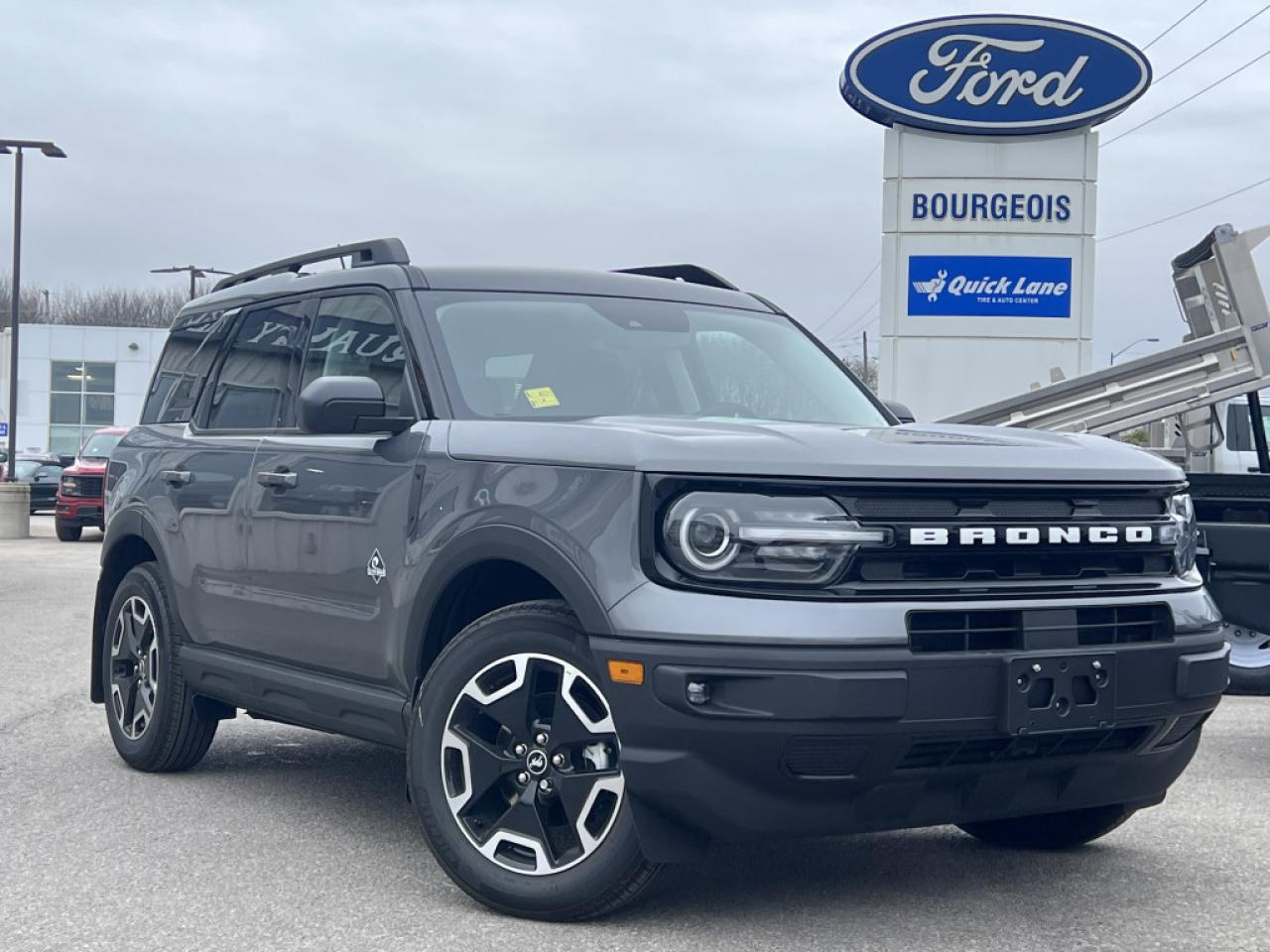 <b>Ford Co-Pilot360 Assist+, Wireless Charging, Premium Audio, Class II Trailer Tow Package!</b><br> <br> <br> <br>  This 2024 Ford Bronco Sport is no rip-off of its bigger brother; its an off road-capable and versatile compact SUV. <br> <br>A compact footprint, an iconic name, and modern luxury come together to make this Bronco Sport an instant classic. Whether your next adventure takes you deep into the rugged wilds, or into the rough and rumble city, this Bronco Sport is exactly what you need. With enough cargo space for all of your gear, the capability to get you anywhere, and a manageable footprint, theres nothing quite like this Ford Bronco Sport.<br> <br> This carbonized grey metallic SUV  has a 8 speed automatic transmission and is powered by a  181HP 1.5L 3 Cylinder Engine.<br> <br> Our Bronco Sports trim level is Outer Banks. Ready for the great outdoors, this Bronco Outer Banks features heated leather seats with feature power lumbar adjustment, a heated leather-wrapped steering wheel, SiriusXM streaming radio and exclusive aluminum wheels. Also standard include voice-activated automatic air conditioning, an 8-inch SYNC 3 powered infotainment screen with Apple CarPlay and Android Auto, smart charging USB type-A and type-C ports, 4G LTE mobile hotspot internet access, proximity keyless entry with remote start, and a robust terrain management system that features the trademark Go Over All Terrain (G.O.A.T.) driving modes. Additional features include blind spot detection, rear cross traffic alert and pre-collision assist with automatic emergency braking, lane keeping assist, lane departure warning, forward collision alert, driver monitoring alert, a rear-view camera, 3 12-volt DC and 120-volt AC power outlets, and so much more. This vehicle has been upgraded with the following features: Ford Co-pilot360 Assist+, Wireless Charging, Premium Audio, Class Ii Trailer Tow Package. <br><br> View the original window sticker for this vehicle with this url <b><a href=http://www.windowsticker.forddirect.com/windowsticker.pdf?vin=3FMCR9C62RRF64202 target=_blank>http://www.windowsticker.forddirect.com/windowsticker.pdf?vin=3FMCR9C62RRF64202</a></b>.<br> <br>To apply right now for financing use this link : <a href=https://www.bourgeoismotors.com/credit-application/ target=_blank>https://www.bourgeoismotors.com/credit-application/</a><br><br> <br/> 7.99% financing for 84 months.  Incentives expire 2024-12-02.  See dealer for details. <br> <br>Discount on vehicle represents the Cash Purchase discount applicable and is inclusive of all non-stackable and stackable cash purchase discounts from Ford of Canada and Bourgeois Motors Ford and is offered in lieu of sub-vented lease or finance rates. To get details on current discounts applicable to this and other vehicles in our inventory for Lease and Finance customer, see a member of our team. </br></br>Discover a pressure-free buying experience at Bourgeois Motors Ford in Midland, Ontario, where integrity and family values drive our 78-year legacy. As a trusted, family-owned and operated dealership, we prioritize your comfort and satisfaction above all else. Our no pressure showroom is lead by a team who is passionate about understanding your needs and preferences. Located on the shores of Georgian Bay, our dealership offers more than just vehiclesits an experience rooted in community, trust and transparency. Trust us to provide personalized service, a diverse range of quality new Ford vehicles, and a seamless journey to finding your perfect car. Join our family at Bourgeois Motors Ford and let us redefine the way you shop for your next vehicle.<br> Come by and check out our fleet of 70+ used cars and trucks and 170+ new cars and trucks for sale in Midland.  o~o