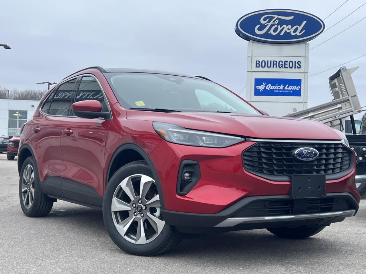 <b>Sunroof, Class II Trailer Tow Package!</b><br> <br> <br> <br>  Welcome. <br> <br><br> <br> This rapid red metallic tinted clearcoat SUV  has a 8 speed automatic transmission and is powered by a  250HP 2.0L 4 Cylinder Engine.<br> <br> Our Escapes trim level is Platinum. This Escape Platinum is a significant step up, with upgrades such as inbuilt navigation, adaptive cruise control, a surround camera system and evasive steering assist. The amazing standard features continue with heated ActiveX synthetic leather seats, a heated leatherette steering wheel, simulated wood interior trim, remote engine start, and an expansive 13.2-inch infotainment screen with wireless Apple CarPlay and Android Auto, SiriusXM satellite radio, and FordPass Connect 4G mobile hotspot internet access. Safety features include blind spot detection, lane keeping assist with lane departure warning, evasive steering assist, forward and rear collision mitigation, and front and rear parking sensors. Additional features include a power liftgate for rear cargo access, aluminum wheels, roof rack rails, LED headlights with automatic high beams, a keypad for extra security, and so much more. This vehicle has been upgraded with the following features: Sunroof, Class Ii Trailer Tow Package. <br><br> View the original window sticker for this vehicle with this url <b><a href=http://www.windowsticker.forddirect.com/windowsticker.pdf?vin=1FMCU9JA5SUA13184 target=_blank>http://www.windowsticker.forddirect.com/windowsticker.pdf?vin=1FMCU9JA5SUA13184</a></b>.<br> <br>To apply right now for financing use this link : <a href=https://www.bourgeoismotors.com/credit-application/ target=_blank>https://www.bourgeoismotors.com/credit-application/</a><br><br> <br/> 5.99% financing for 84 months.  Incentives expire 2024-12-02.  See dealer for details. <br> <br>Discount on vehicle represents the Cash Purchase discount applicable and is inclusive of all non-stackable and stackable cash purchase discounts from Ford of Canada and Bourgeois Motors Ford and is offered in lieu of sub-vented lease or finance rates. To get details on current discounts applicable to this and other vehicles in our inventory for Lease and Finance customer, see a member of our team. </br></br>Discover a pressure-free buying experience at Bourgeois Motors Ford in Midland, Ontario, where integrity and family values drive our 78-year legacy. As a trusted, family-owned and operated dealership, we prioritize your comfort and satisfaction above all else. Our no pressure showroom is lead by a team who is passionate about understanding your needs and preferences. Located on the shores of Georgian Bay, our dealership offers more than just vehiclesits an experience rooted in community, trust and transparency. Trust us to provide personalized service, a diverse range of quality new Ford vehicles, and a seamless journey to finding your perfect car. Join our family at Bourgeois Motors Ford and let us redefine the way you shop for your next vehicle.<br> Come by and check out our fleet of 60+ used cars and trucks and 180+ new cars and trucks for sale in Midland.  o~o