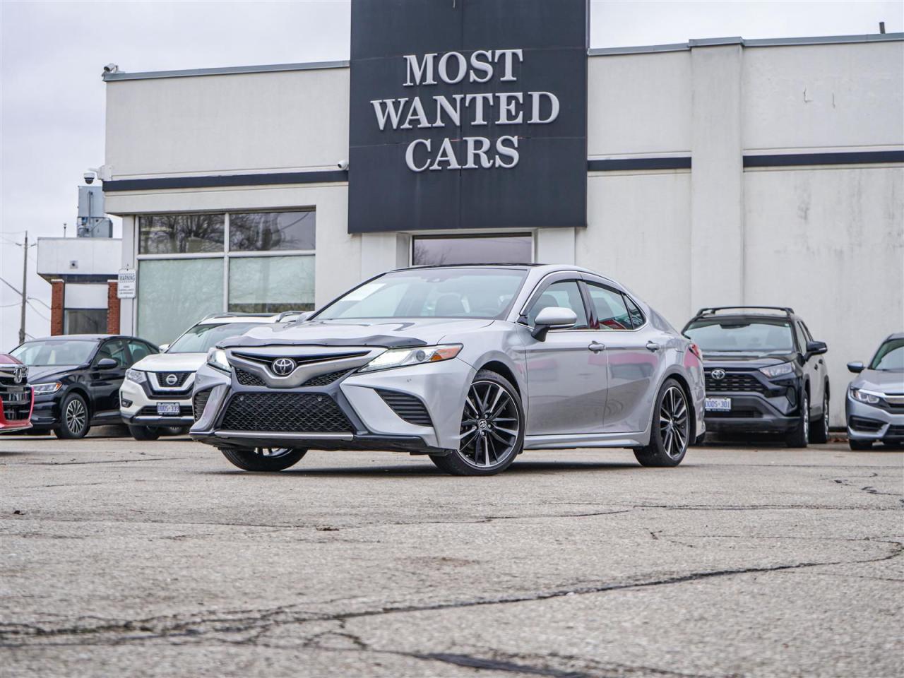 <div style=text-align: justify;><span style=font-size:14px;><span style=font-family:times new roman,times,serif;>This 2018 Toyota Camry has a CLEAN CARFAX with no accidents and is also a Canadian vehicle with Villa Toyota service records. High-value options included with this vehicle are; blind spot indicators, lane departure warning, adaptive cruise control, pre-collision, paddle shifters, black leather / heated / power seats, front & rear sensor, panoramic sunroof, convenience entry, push button, app connect, back up camera, touchscreen and 17” alloy rims, offering immense value.</span></span><br /><br /><span style=font-size:14px;><span style=font-family:times new roman,times,serif;>Why buy from us?<br /> <br />Most Wanted Cars is a place where customers send their family and friends. MWC offers the best financing options in Kitchener-Waterloo and the surrounding areas. Family-owned and operated, MWC has served customers since 1975 and is also DealerRater’s 2022 Provincial Winner for Used Car Dealers. MWC is also honoured to have an A+ standing on Better Business Bureau and a 4.8/5 customer satisfaction rating across all online platforms with over 1400 reviews. With two locations to serve you better, our inventory consists of over 150 used cars, trucks, vans, and SUVs.<br /> <br />Our main office is located at 1620 King Street East, Kitchener, Ontario. Please call us at 519-772-3040 or visit our website at www.mostwantedcars.ca to check out our full inventory list and complete an easy online finance application to get exclusive online preferred rates.<br /> <br />*Price listed is available to finance purchases only on approved credit. The price of the vehicle may differ from other forms of payment. Taxes and licensing are excluded from the price shown above*</span></span></div><br />