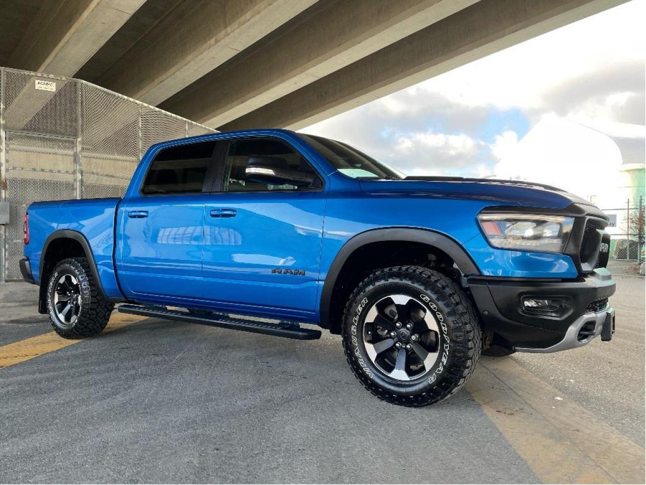 RAM 1500 REBEL CREW CAB 4X4 
Exterior Color: Hydro Blue Pearl Interior Color: Black interior / Red seats 
Interior: Vinyl front bucket seats with tread pattern cloth Engine: 3.0L V6 turbocharged diesel engine Transmission: 8speed automatic transmission 
STANDARD EQUIPMENT (UNLESS REPLACED BY OPTIONAL EQUIPMENT)
3.92 rear axle ratio
ELocker rear axle
FullSpeed Forward Collision Warning Plus
Sport performance hood
Class IV hitch receiver
ParkView Rear BackUp Camera
Brake Assist
Electronic Stability Control
Ready Alert Braking
Hill Start Assist
Traction Control
Electronic Roll Mitigation
Trailer Sway Control
Rain Brake Support
Supplemental front seatmounted side air bags
Advanced multistage front air bags
Supplemental side curtain air bags
OPTIONAL EQUIPMENT (May Replace Standard Equipment)
Hydro Blue Pearl $395
Customer Preferred Package 28W 
Cold Weather Group $225
Mopar Winter front grille cover 
Comfort & Convenience Group $1,395
Power 2way front passenger lumbar adjust 
Secondrow heated seats 
Power 8way Driver/ Passenger seats 
Wireless charging pad 
Monotone paint 
Level 2 Equipment Group $3,195
Connectivity  US/Canada 
Media hub with 2 USB charging ports 
Front heated seats 
Rear underseat compartment storage 
Remote proximity keyless entry 
A/C with dualzone automatic temperature control 
Heated steering wheel 
Google Android Auto 
Apple CarPlay capable 
4G LTE WiFi hot spot 
Power adjustable pedals 
Remote start system 
ParkSense Front and Rear Park Assist with stop 
New Chip Supplier Tracking 
Electronic shiftondemand transfer case $595
3.0L V6 turbocharged diesel engine $3,900
Rear wheelhouse liners 
9 Alpine speakers with subwoofer 
Uconnect 5W NAV with 12inch display 
Connectivity  US/Canada 
Connected travel & traffic services 
Google Android Auto 
12inch touchscreen 
Apple CarPlay capable 
4G LTE WiFi hot spot 
SiriusXM with 360L ondemand content 
Federal A/C Excise Tax $100
Destination Charge $2,095
Price does not include $599 documentation fee.