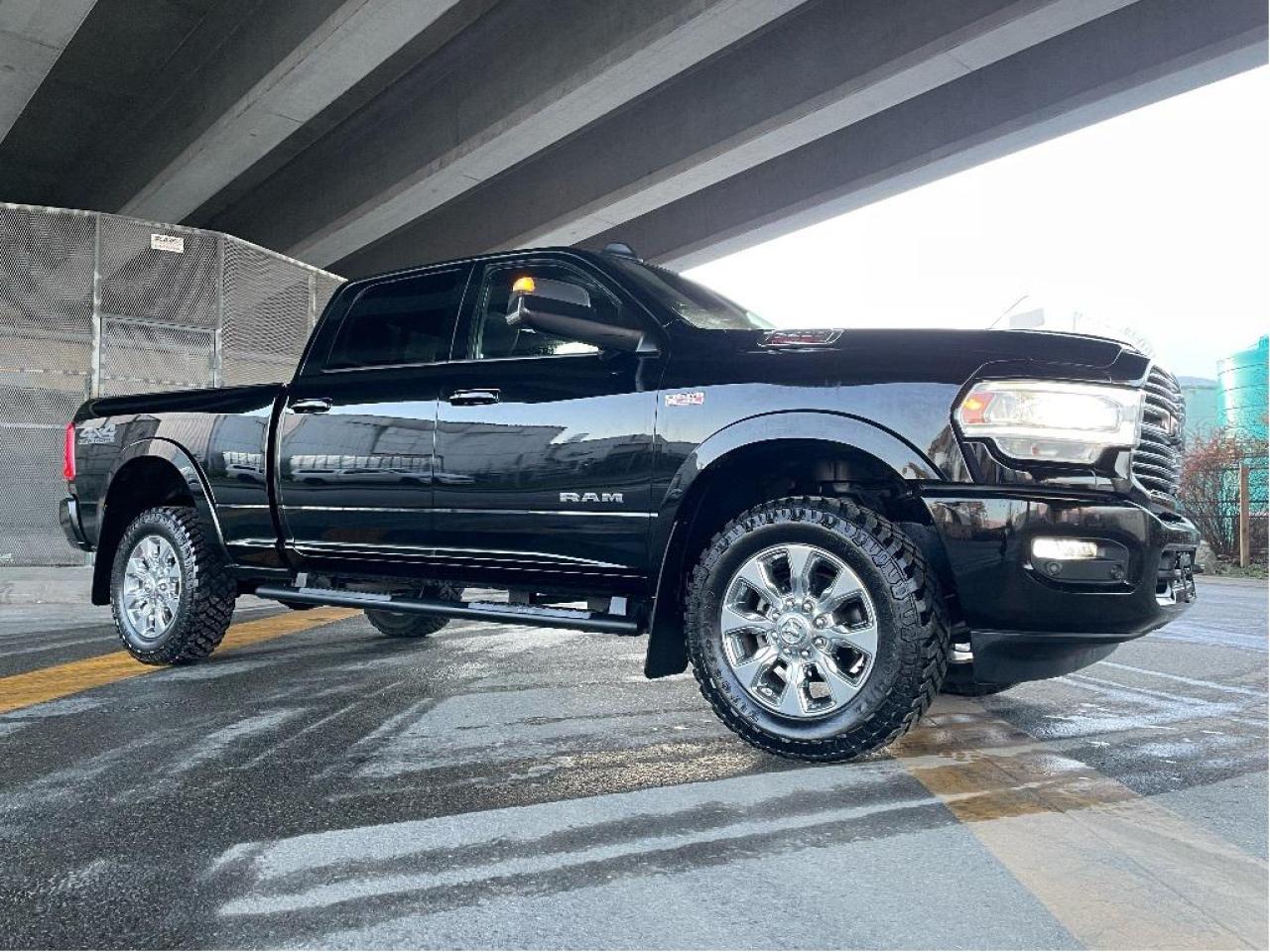 RAM 2500 LARAMIE CREW CAB 4X4 
Exterior Color: Diamond Black Crystal Pearl Interior Color: Black interior / Black seats 
Interior: Leatherfaced front vented front bucket seats 
Engine: 6.4L HEMI V8 engine with FuelSaver MDS Transmission: 8speed automatic transmission 
STANDARD EQUIPMENT (UNLESS REPLACED BY OPTIONAL EQUIPMENT)
FUNCTIONAL / SAFETY FEATURES
ParkView Rear BackUp Camera
ParkSense Front and Rear Park Assist System
Class V hitch receiver
Trailer Brake Control
Security alarm
Keyless Enter n Go with pushbutton start
Traction Control
Remote start system
Brake Assist
Ready Alert Braking
Hill Start Assist
Electronic Roll Mitigation
Trailer Sway Control
Remote proximity keyless entry
Advanced multistage front air bags
Supplemental side curtain air bags
Supplemental side air bags
Supplemental front seatmounted side air bags
Electronic shiftonthefly transfer case
Bright, power folding trailer tow mirrors
4wheel antilock disc brakes
Electronic Stability Control
Tire pressure monitoring system
Remote keyless entry
Sentry Key antitheft engine immobilizer
OPTIONAL EQUIPMENT (May Replace Standard Equipment)
Diamond Black Crystal Pearl $275
Leatherfaced front vented front bucket seats $1,400
Fulllength upgraded floor console 
Ramcharger wireless charging pad 
Customer Preferred Package 2ZH 
Towing Technology Group $425
Power folding, heated mirrors with driver memory 
Exterior mirrors with memory settings 
Power, convex auxiliary exterior mirrors 
Centre highmounted stop lamp with camera 
Mirrormounted auxiliary reverse lamps 
Surround View Camera System 
Trailer reverse guidance 
Safety Group $1,000
Forward Collision Warning with Active Braking 
Adaptive Cruise Control with Stop 
Protection Group $175
Tow hooks 
Transfer case skid plate 
Sport Appearance Package $495
Bed Utility Group $750
LED bed lighting 
Deployable bed step 
Sprayin bedliner 
OffRoad Group $395
Hill Descent Control 
Offroad decal 
Front performancetuned shock absorbers 
Rear performancetuned shock absorbers 
Tow hooks 
Transfer case skid plate 
Laramie Level 2 Equipment Group $3,195
Front ventilated seats 
Secondrow infloor storage bins 
Power folding, heated mirrors with driver memory 
Rainsensing windshield wipers 
Remote tailgate release 
GPS navigation 
Secondrow heated seats 
Exterior mirrors with memory settings 
Radio, driver seat, mirrors & pedals memory setting 
Power, convex auxiliary exterior mirrors 
Mirrormounted auxiliary reverse lamps 
17speaker high performance audio 
Singledisc remote CD player 
1year SiriusXM Guardian subscription 
Uconnect 4C NAV with 8.4inch display 
5year SiriusXM Traffic subscription 
5year SiriusXM Travel Link subscription 
Power adjustable pedals with memory 
BlindSpot and CrossPath Detection (Truck only) 
Antispin differential rear axle $525
Power sunroof $1,425
LT275/70R18E OWL On/OffRoad tires $350
Uconnect 12.0 with navigation $1,000
12inch touchscreen 
SiriusXM with 360L ondemand content 
Federal A/C Excise Tax $100
Destination Charge $1,895Price does not include $599 documentation fee.