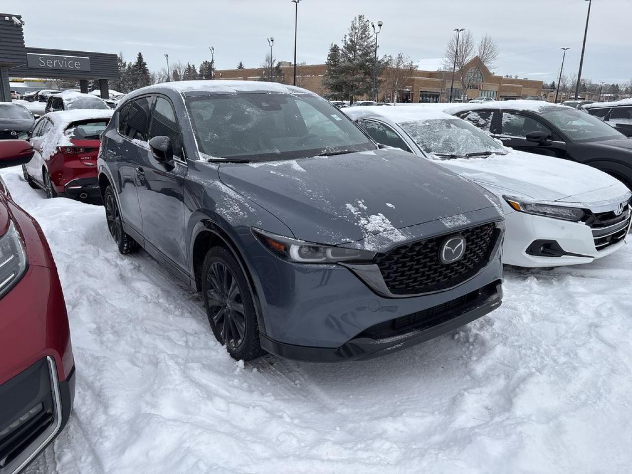 <p>Fully Inspected, ALL Work Complete and Included in Price! Call Us For More Info at 587-409-5859</p>  <p>The 2023 Mazda CX-5 Sport Design Turbo AWD is where sophistication meets spirited performance. Beneath its sleek, sculpted exterior lies a 2.5L turbocharged engine ready to deliver up to 256 horsepower, making your everyday commute feel more like a victory lap. Paired with Mazdas i-Activ AWD, this SUV tackles tight corners and tricky weather with confident ease.</p>  <p>Inside, youll find a cabin designed to impress, featuring premium materials, red contrast stitching, and a layout that feels both sporty and luxurious. The heated front seats and leather-wrapped steering wheel are perfect companions for chilly mornings, while the 10.25-inch infotainment screen keeps you seamlessly connected via Apple CarPlay and Android Auto.</p>  <p>Whether youre zipping through city streets or heading off for a weekend adventure, the CX-5 Sport Design Turbo is built for excitement and practicality. With 2,000 lbs of towing capacity and ample cargo space, its as ready for road trips as it is for groceries.</p>  <p>Mazdas reputation for safety shines here too, thanks to features like adaptive cruise control, lane-keeping assist, and blind-spot monitoring. The 2023 CX-5 Sport Design Turbo AWD doesnt just move youit inspires you to enjoy the journey.</p>  <p>Call 587-409-5859 for more info or to schedule an appointment! Listed Pricing is valid for 72 hours. Financing is available, please see dealer for term availability and interest rates. AMVIC Licensed Business.</p>