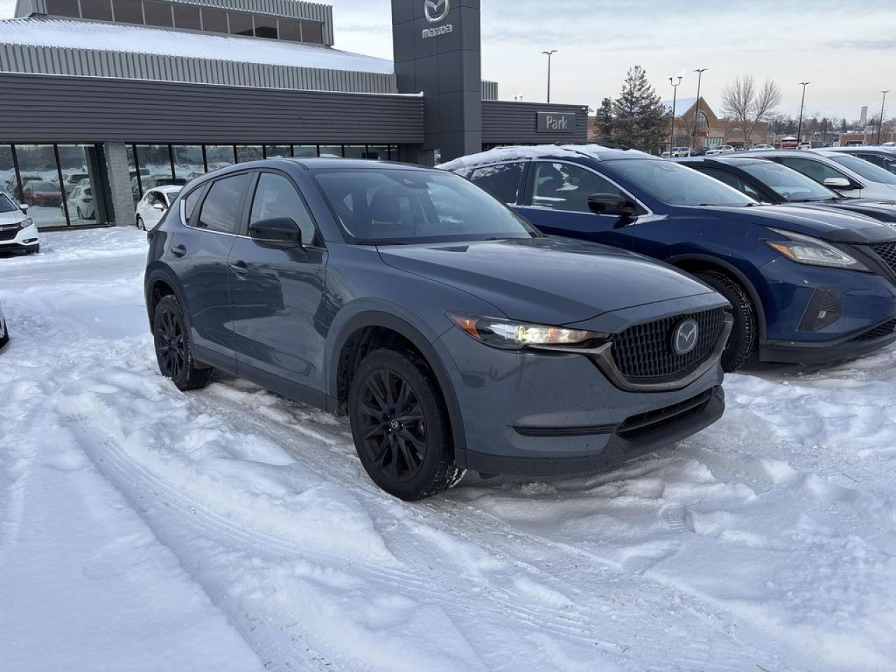 <p>Fully Inspected, ALL Work Complete and Included in Price! Call Us For More Info at 587-409-5859</p>  <p>Looking for an SUV with personality? Meet the 2021 Mazda CX-5 Kuro Edition AWD, where bold style meets Mazdas renowned driving dynamics. Cloaked in exclusive Polymetal Grey Metallic, the Kuro Edition turns heads with black alloy wheels, matching side mirrors, and a touch of elegance that screams sophistication, but make it sporty.</p>  <p>Slide inside, and youll be greeted by a luxurious interior featuring Garnet Red leather-trimmed seats and sleek black accents. Comfort is key with heated front seats, a leather-wrapped steering wheel, and a power moonroof to let the sunshine (or moonlight) in. Mazdas infotainment system, with a 10.25-inch display, Apple CarPlay, and Android Auto, ensures you stay connected and entertained wherever the road takes you.</p>  <p>Under the hood, the 2.5L SkyActiv engine paired with Mazdas intelligent AWD system delivers an engaging and smooth ride, even in less-than-ideal conditions. Safety? Covered, thanks to features like blind-spot monitoring, rear cross-traffic alert, and adaptive cruise control.</p>  <p>Perfect for urban adventures or weekend getaways, the CX-5 Kuro Edition blends style, performance, and practicality into one stunning package. Prepare to fall in love every time you hit the road!</p>  <p>Call 587-409-5859 for more info or to schedule an appointment! Listed Pricing is valid for 72 hours. Financing is available, please see dealer for term availability and interest rates. AMVIC Licensed Business.</p>