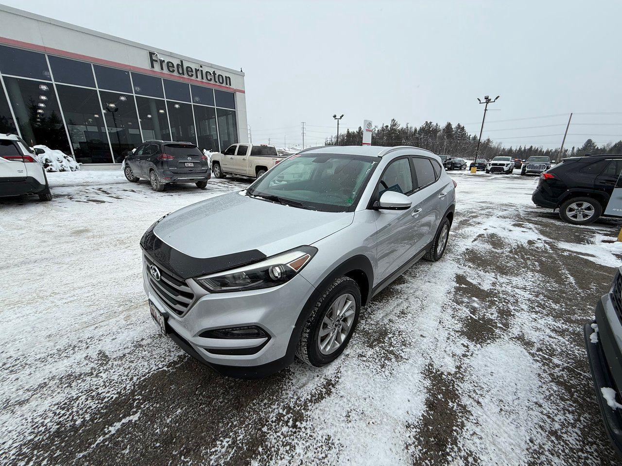 The 2017 Hyundai Tucson Limited in white is a sleek and versatile all-wheel-drive SUV designed for comfort, safety, and style. Its exterior features heated mirrors, fog lights, integrated turn signal mirrors, and privacy glass, while the interior offers heated front and rear seats, a heated steering wheel, and dual-zone air conditioning. Advanced tech includes Bluetooth, a rearview camera, satellite radio, and steering wheel audio controls for a connected driving experience. Safety highlights like blind-spot monitoring, cross-traffic alert, ABS, and multiple airbags ensure peace of mind. With modern design and premium features, the Tucson Limited is ready for any journey.

<span>Why choose to buy from Fredericton Toyota? When you buy from us, you’re not just a customer — you’re part of the family, and we’re committed to providing exceptional service every step of the way.</span>