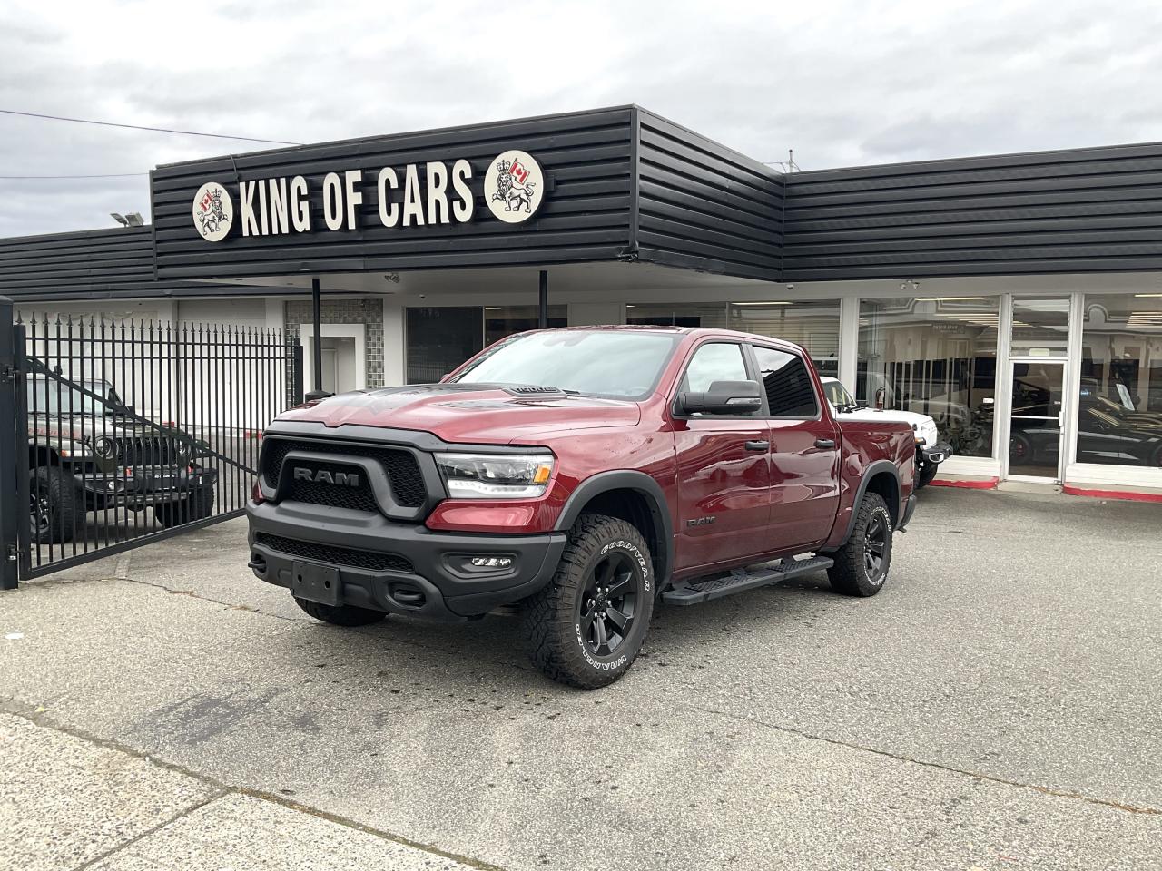 2023 RAM 1500 REBEL  - 4X4 - E TORQUE  Stock Number: P215186    This truck offers the perfect mix of luxury, toughness, and cutting-edge technology. Whether youre blazing trails, towing your toys, or cruising the streets, the RAM 1500 REBEL delivers everything you need and more.Performance and Capability5.7L HEMI® V8 Engine with Multi-Displacement System (MDS) & e Torque for enhanced power and better fuel economy.Off-road-ready with skid plates, off-road suspension, and all-terrain tires.Exceptional towing and hauling capabilities for all your work or adventure needs.Rugged DesignAggressive styling with the REBEL trim, black accents, and a bold stance that demands attention.Durable truck bed with versatile tie-down points for gear, equipment, or weekend toys.Advanced TechnologyIntuitive Uconnect® infotainment system with a vibrant touchscreen display.Stay connected on the go with Apple Ca rPlay® and Android Auto integration.Hands-free calling and media streaming with Bluetooth connectivity.Interior ComfortPremium cloth and vinyl-trimmed seats that are as durable as they are comfortable.Spacious interior with thoughtful storage options and all-weather mats.Dual-zone climate control ensures a comfortable ride no matter the weather.Safety & Peace of MindTraction Control System (TCS): This advanced system prevents wheel slippage during acceleration, especially on slippery or uneven surfaces. It uses sensors to monitor wheel speed and applies brakes selectively or reduces engine power to maintain optimal grip and control, ensuring stability in challenging conditions.Advanced safety features like Electronic Stability Control, traction control, and multiple airbags.Rearview camera for easy parking and hitching. Call Us Now: 604-533-4499              Text Us: 604-360-0123                          Apply Online: Visit kingofcarsbc.com to get a FREE Pre-Approval                           Plus Administration Fee of $895 and Taxes             Dealer #31301             All finance options are subject to OAC (On Approved Credit).                          