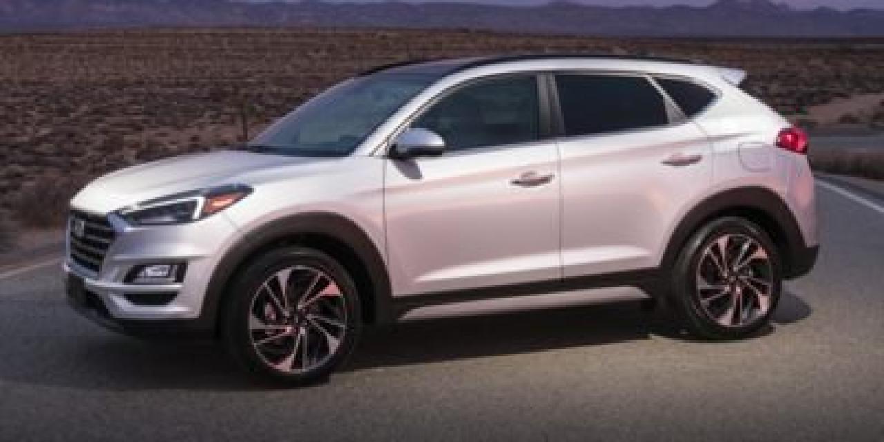 <b>Leather Seats, Sunroof, Blind Spot Detection, Heated Seats, Heated Steering Wheel, Power Liftgate, Apple CarPlay, Android Auto</b><br> <br>    Full of amazing features, this 2020 Tucson is more than a capable and reliable family SUV, it represents the new wave of modern SUVs. This  2020 Hyundai Tucson is fresh on our lot in Kingston. <br> <br>2020 Hyundai Tucson is more than just a sport utility vehicle, its the SUV thats always up for your adventures. With innovative features to keep you connected like standard Apple CarPlay and Android Auto smartphone connectivity, capable and efficient performance and heaps of built-in safety features, its always ready when you are. This 2020 Hyundai Tucson is ready to show you what an affordable family SUV should be.This  SUV has 103,830 kms. Its  white in colour  . It has an automatic transmission and is powered by a  smooth engine.  <br> <br> Our Tucsons trim level is Luxury. Upgrading to this all wheel drive Luxury trim over the lower Preferred trim is as great choice as you will get a power rear liftgate, leather heated seats, surround view monitoring and a second row USB port. It also includes aluminum wheels, a blind spot detection system with rear cross traffic alerts and lane change assist, a heated leather wrapped steering wheel and drive mode select. This Luxury trim also receives a 7 inch colour touch screen display with Apple CarPlay and Android Auto, LED daytime running lights, a 60/40 split rear seat, remote keyless entry with a proximity key for push button start and a rear view camera. Additional features include a panoramic sunroof, Bluetooth hands-free phone system with voice recognition, dual zone climate control, an 8 way power driver seat plus much more!<br> <br>To apply right now for financing use this link : <a href=https://www.taylorautomall.com/finance/apply-for-financing/ target=_blank>https://www.taylorautomall.com/finance/apply-for-financing/</a><br><br> <br/><br> Buy this vehicle now for the lowest bi-weekly payment of <b>$153.78</b> with $0 down for 96 months @ 9.99% APR O.A.C. ( Plus applicable taxes -  Plus applicable fees   ).  See dealer for details. <br> <br>For more information, please call any of our knowledgeable used vehicle staff at (613) 549-1311!<br><br> Come by and check out our fleet of 60+ used cars and trucks and 170+ new cars and trucks for sale in Kingston.  o~o