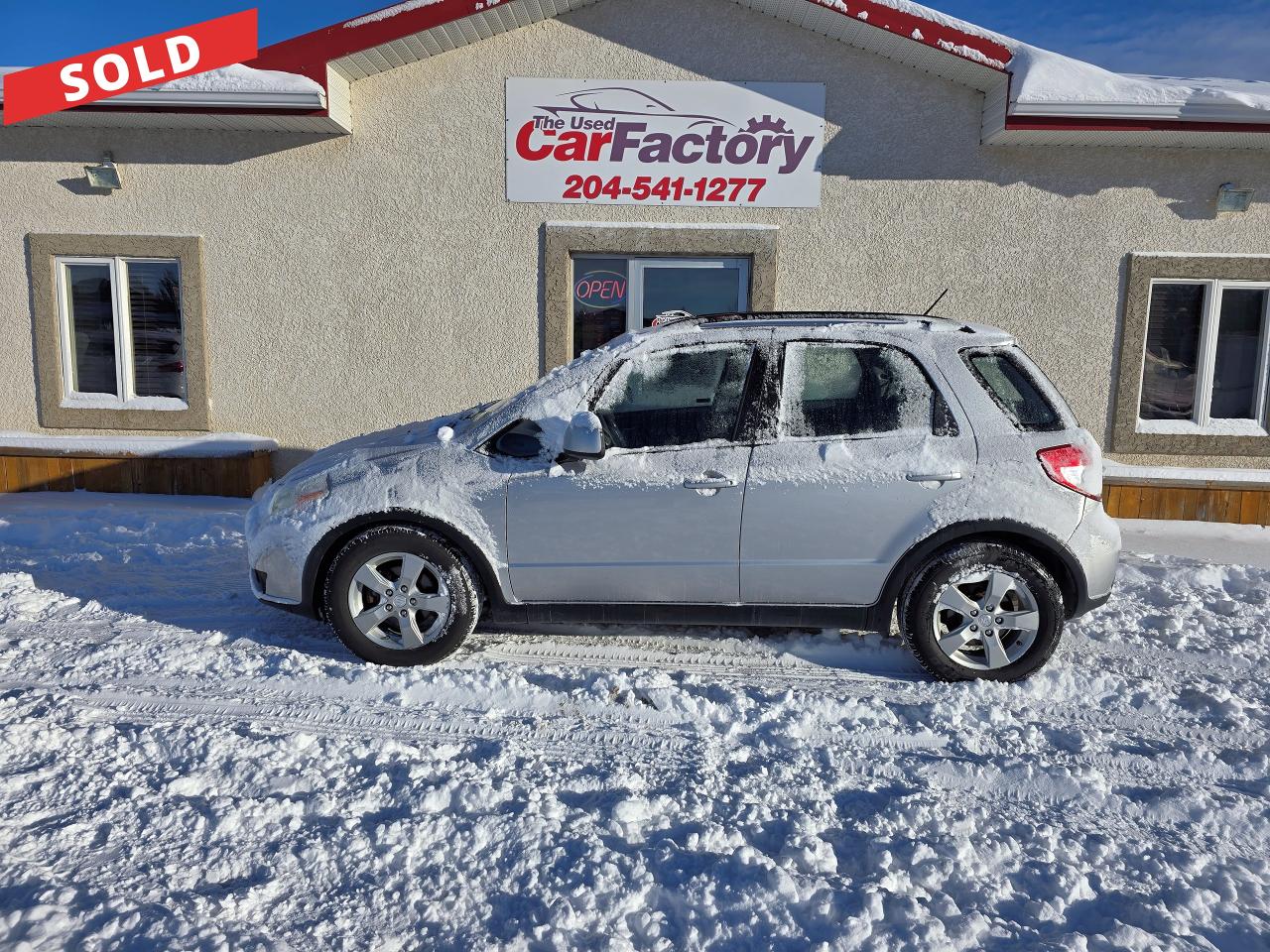 <p>***SOLD***</p><p>Looking for a reliable and versatile vehicle that can handle anything you throw at it? Look no further than this 2012 Suzuki SX4. This silver hatchback boasts a sleek and stylish design, offering ample cargo space for all your adventures. With its 2.0L I4 engine and automatic transmission, this SX4 delivers a smooth and responsive driving experience.</p><p>This well-maintained vehicle comes equipped with a comprehensive list of features designed to enhance your comfort and safety. Enjoy the convenience of power windows, locks, and mirrors, along with heated mirrors for those chilly mornings. Stay connected with the built-in CD player, and cruise in comfort with the help of cruise control and tilt steering wheel. With 107,315km on the odometer, this SX4 JX is ready for many more years of reliable service.</p><p>Here are five features that make this Suzuki SX4 a standout choice:</p><ul><li><strong>All Wheel Drive:</strong> Conquer any road condition with confidence.</li><li><strong>Anti-theft System:</strong> Drive with peace of mind knowing your investment is protected.</li><li><strong>Keyless Entry:</strong> Enjoy the convenience of unlocking your vehicle without fumbling for your keys.</li><li><strong>Power Steering:</strong> Effortless maneuvering for a more enjoyable driving experience.</li><li><strong>Side Air Bags:</strong> Providing added safety and peace of mind for you and your passengers.</li></ul><p>We offer on -the- spot financing; we finance all levels of credit.</p><p>Comes with a 3 month Warranty at no extra cost, several upgrade options available.</p><p>All our vehicles come with a Manitoba safety.</p><p>Proud members of The Manitoba Used Car Dealer Association as well as the Manitoba Chamber of Commerce.</p><p>All payments, and prices, are plus applicable taxes. The Used Car Factorys Dealers permit is #4821</p>