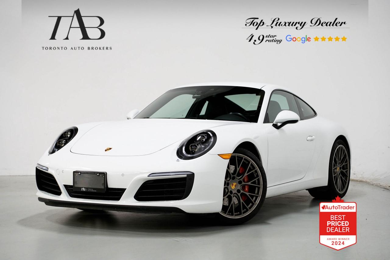 This 2018 Porsche 911 Carrera S is a 1-Owner Local Ontario vehicle with Clean Carfax Report. It is a masterpiece of precision engineering and timeless design, delivering a driving experience thats nothing short of exhilarating. With a manual transmission and the iconic Sport Chrono Package, this Carrera S offers pure driving pleasure for enthusiasts who appreciate performance in its most engaging form. The 20-inch wheels and unmistakable 911 silhouette make it a true standout on any road.

Key Features:

3.0L Twin-Turbocharged Flat-6 Engine 
Manual Transmission 
Sport Chrono Package 
Rear-Wheel Drive with Porsche Stability Management (PSM)
20-Inch Carrera S Alloy Wheels
PASM Sport Suspension with Lower Ride Height
Porsche Active Aerodynamics (rear spoiler)
Full Leather Interior with Heated and Ventilated Sport Seats
Porsche Communication Management (PCM) with Navigation
Apple CarPlay Compatibility
BOSE Surround Sound System
Porsche DYNAMIC Light system plus
Sport Exhaust system 
Smoking Package 
GT Sport Steering wheel 
Adaptive Sports seats plus with Memory Package 
Premium Package Plus 
Rear Parking Sensors and Backup Camera
Dual-Zone Automatic Climate Control

NOW OFFERING 3 MONTH DEFERRED FINANCING PAYMENTS ON APPROVED CREDIT.

WE OFFER THE BEST FINANCE RATES, AND DONT CHARGE ANY FEE

Looking for a top-rated pre-owned luxury car dealership in the GTA? Look no further than Toronto Auto Brokers (TAB)! Were proud to have won multiple awards, including the 2024 AutoTrader Best Priced Dealer, 2024 CBRB Dealer Award, the Canadian Choice Award 2024, the 2024 BNS Award, the 2024 Three Best Rated Dealer Award, and many more!

With 30 years of experience serving the Greater Toronto Area, TAB is a respected and trusted name in the pre-owned luxury car industry. Our 30,000 sq.Ft indoor showroom is home to a wide range of luxury vehicles from top brands like BMW, Mercedes-Benz, Audi, Porsche, Land Rover, Jaguar, Aston Martin, Bentley, Maserati, and more. 

At TAB, were committed to providing a no-pressure environment and honest work ethics. As a family-owned and operated business, we treat every customer like family and ensure that every interaction is a positive one. Come experience the TAB Lifestyle at its truest form, luxury car buying has never been more enjoyable and exciting!

We offer a variety of services to make your purchase experience as easy and stress-free as possible. From competitive and simple financing and leasing options to extended warranties, aftermarket services, and full history reports on every vehicle, we have everything you need to make an informed decision. We welcome every trade, even if youre just looking to sell your car without buying, and when it comes to financing or leasing, we offer same day approvals, with access to over 50 lenders, including all of the banks in Canada. Feel free to check out your own Equifax credit score without affecting your credit score, simply click on the Equifax tab above and see if you qualify.

So if youre looking for a luxury pre-owned car dealership in Toronto, look no further than TAB! We proudly serve the GTA, including Toronto, Etobicoke, Woodbridge, North York, York Region, Vaughan, Thornhill, Richmond Hill, Mississauga, Scarborough, Markham, Oshawa, Peteborough, Hamilton, Newmarket, Orangeville, Aurora, Brantford, Barrie, Kitchener, Niagara Falls, Oakville.

Call us today or visit our website to learn more about our inventory and services. And remember, all prices exclude applicable taxes and licensing, and vehicles can be certified at an additional cost of $799.