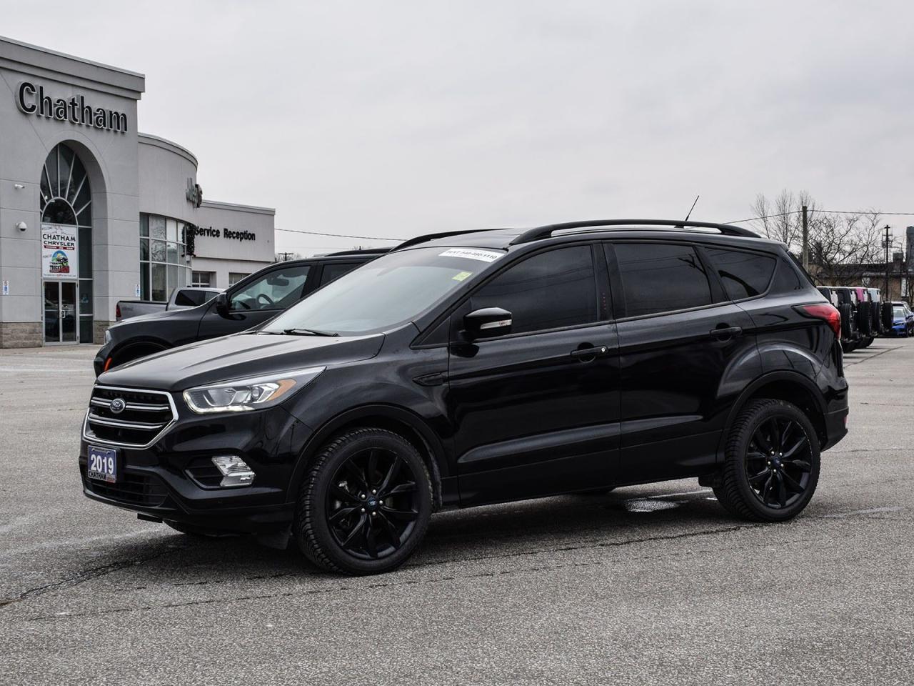 2019 Ford Escape 4D Sport Utility Titanium Black 4WD, Navigation System, Power Liftgate. 4WD EcoBoost 2.0L I4 GTDi DOHC Turbocharged VCT 6-Speed Automatic<br><br><br>Here at Chatham Chrysler, our Financial Services Department is dedicated to offering the service that you deserve. We are experienced with all levels of credit and are looking forward to sitting down with you. Chatham Chrysler Proudly serves customers from London, Ridgetown, Thamesville, Wallaceburg, Chatham, Tilbury, Essex, LaSalle, Amherstburg and Windsor with no distance being ever too far! At Chatham Chrysler, WE CAN DO IT!