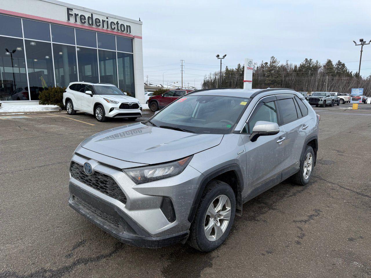 The 2019 Toyota RAV4 Hybrid combines style, efficiency, and safety in a dynamic package. It features premium fabric seats with manual adjustments for the driver, including seat height, lumbar support, and fore/aft positioning. Comfort is enhanced with heated front seats, dual-zone automatic climate control, and an acoustic front windshield that minimizes noise. The spacious interior also offers a 60/40 split rear seat, a center armrest, and an illuminated entry system. The vehicle’s exterior boasts all-season tires, color-keyed door handles, roof rails, and hybrid blue-accented emblems, while its power-adjustable, heated mirrors provide added convenience.

Safety is prioritized with features like blind spot monitoring, a pre-collision system with pedestrian and bicycle detection, and eight airbags, including a driver’s knee airbag and rear side curtain airbags. The RAV4 Hybrid also includes advanced driver-assistance systems, such as lane departure alert with steering assist, dynamic radar cruise control, and lane tracing assist. The backup camera, electronic brake-force distribution, and vehicle stability control further enhance driving confidence.

On the tech front, the RAV4 Hybrid offers Apple CarPlay compatibility, Entune 3.0 with app suite connectivity, Bluetooth, and a voice recognition system. The intuitive 17 aluminum alloy wheels are complemented by the vehicle’s efficient Hybrid Synergy Drive and continuous variable transmission (CVT) for a smooth and eco-friendly driving experience. Whether navigating city streets or tackling tough terrain, the RAV4 Hybrid ensures a secure, comfortable, and connected ride.

<span>Why choose to buy from Fredericton Toyota? When you buy from us, you’re not just a customer — you’re part of the family, and we’re committed to providing exceptional service every step of the way.</span>