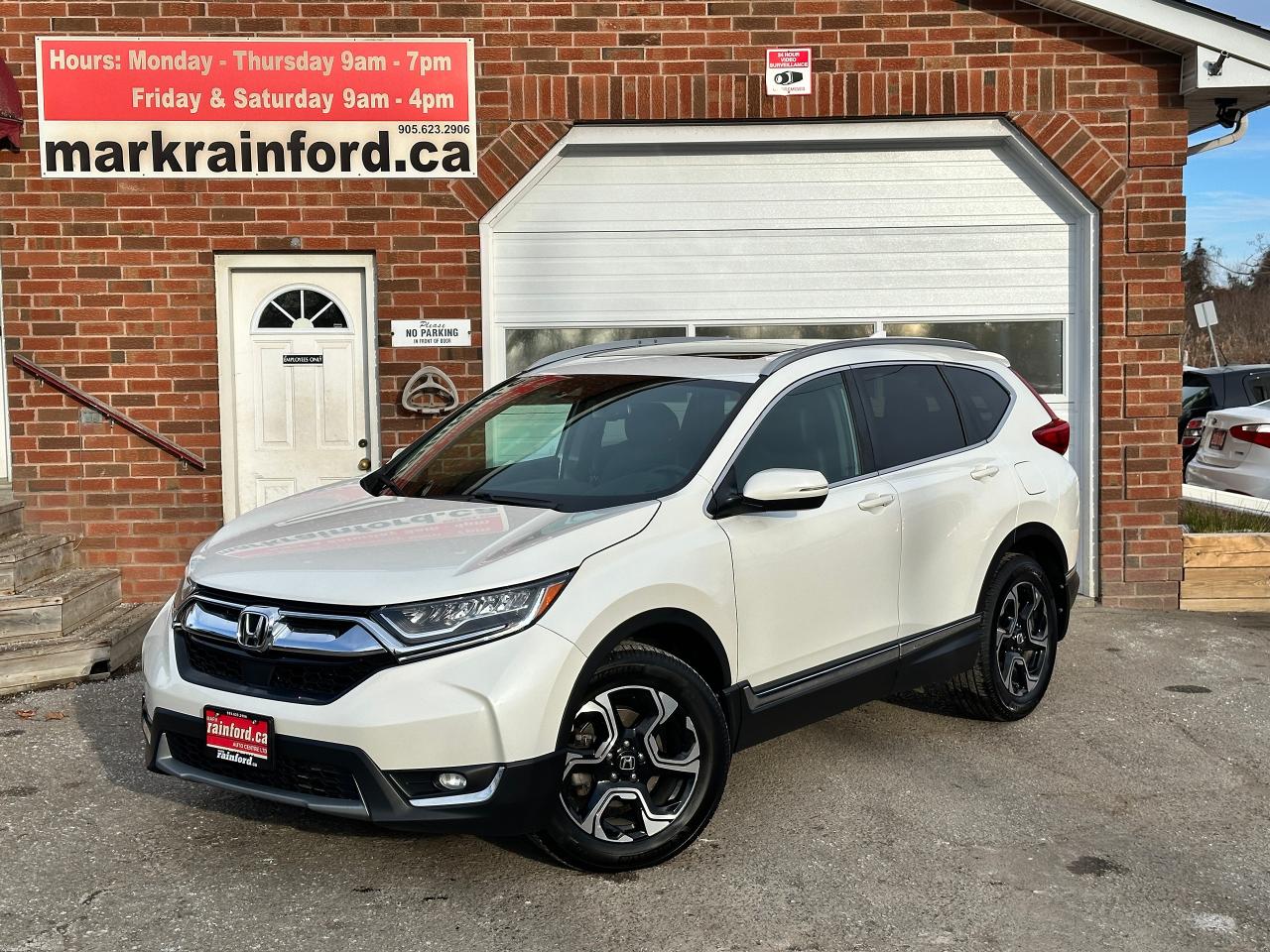 <p>Super-Clean LOW KM Honda CR-V from Brockville, ON! This Touring AWD model comes with amazing options inside and out, and it looks amazing in its White paint and factory alloy wheels! The exterior features keyless entry with remote start, proximity keys, and remote opening rear liftgate, a large factory panoramic sunroof, automatic headlights, foglights, colour-matched side mirrors with integrated mirror turn signals and blind-spot monitors, lane keeping assist and forward warnings, rear cross-traffic warning, tinted rear privacy glass, a sleek rear spoiler, sporty dual exhaust, chromed accents, roof rack rails, gorgeous factory alloy wheels, a peppy fuel efficient 1.5L Turbocharged 4-Cylinder Engine and CVT Automatic Transmission powering the All-Wheel-Drive System! The interior is clean and comfortable with heated leather power-adjustable front seats with driver lumbar and memory controls, heated rear seats, power door locks, mirrors and windows, a powered rear liftgate, spacious rear seating, a large cargo area with privacy shade, heated leather-wrapped steering wheel with audio and cruise controls, Adaptive Cruise Control, an easy-to-read and use gauge cluster, push-button start, a large central touch screen AM/FM/XM Satellite Radio with Bluetooth, Navigation, HondaLink, Apple CarPlay, Android Auto, and Backup Camera, Dual-Zone A/C climate control with front and rear window defrost settings, wiper blade defrost setting, ECON driving mode for improved fuel economy, multiple USB/12V accessory ports, and more!</p><p> </p><p>Carfax Attached, LOW KM, Great Options and Awesome on Fuel!</p><p> </p><p>Call (905) 623-2906</p><p> </p><p>Text Ryan: (905) 429-9680 or email: ryan@markrainford.ca</p><p> </p><p>Text Mark: (905) 431-0966 or email: mark@markrainford.ca</p>