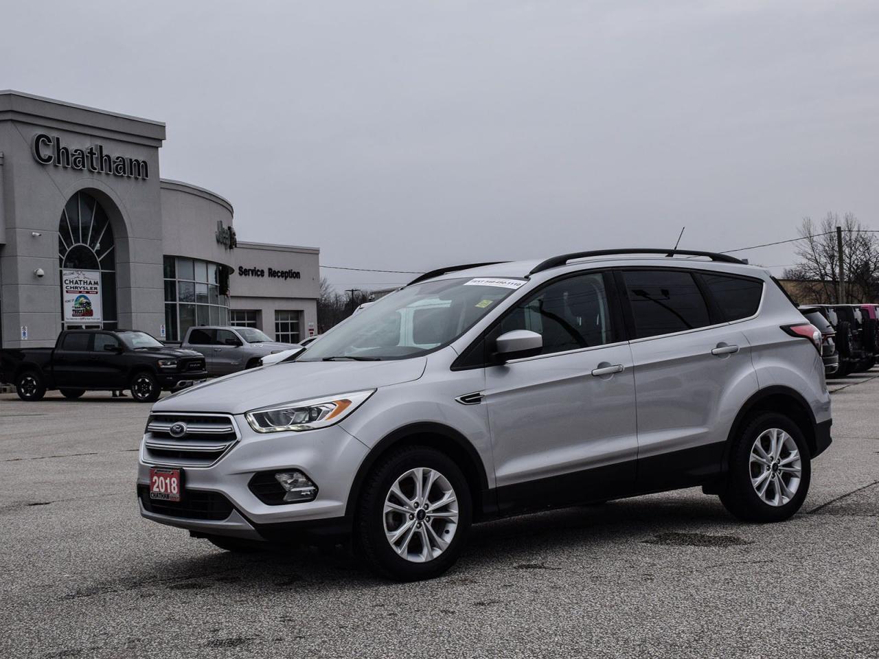 2018 Ford Escape 4D Sport Utility SEL Silver FWD 1.5L EcoBoost 6-Speed Automatic<br><br><br>Reviews:<br>  * Owners appreciate a modern and unique cabin layout, peace of mind in bad weather, and pleasing performance from the turbocharged engines, particularly the larger 2.0L unit. Controls are said to be easy to use, and interfaces are easily learned. Plenty of at-hand storage is fitted within reach of all occupants to help keep organized and tidy on the move, and the tall and upright driving position helps add confidence. Good brake feel is also noted, particularly during hard stops. Source: autoTRADER.ca<br><br><br>Here at Chatham Chrysler, our Financial Services Department is dedicated to offering the service that you deserve. We are experienced with all levels of credit and are looking forward to sitting down with you. Chatham Chrysler Proudly serves customers from London, Ridgetown, Thamesville, Wallaceburg, Chatham, Tilbury, Essex, LaSalle, Amherstburg and Windsor with no distance being ever too far! At Chatham Chrysler, WE CAN DO IT!