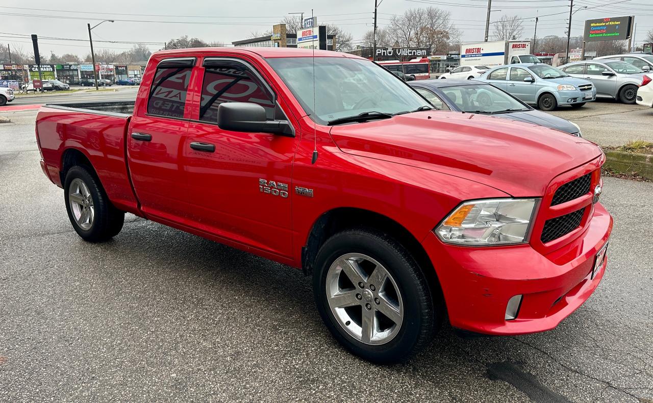 2017 RAM 1500 4WD QUAD CAB 140.5" ST Photo3